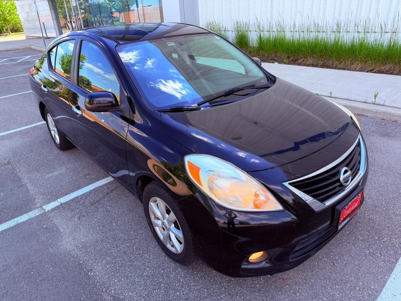 2012 Nissan Versa 1.6 S 4dr Sedan (1.6L 4cyl 5M) Photo