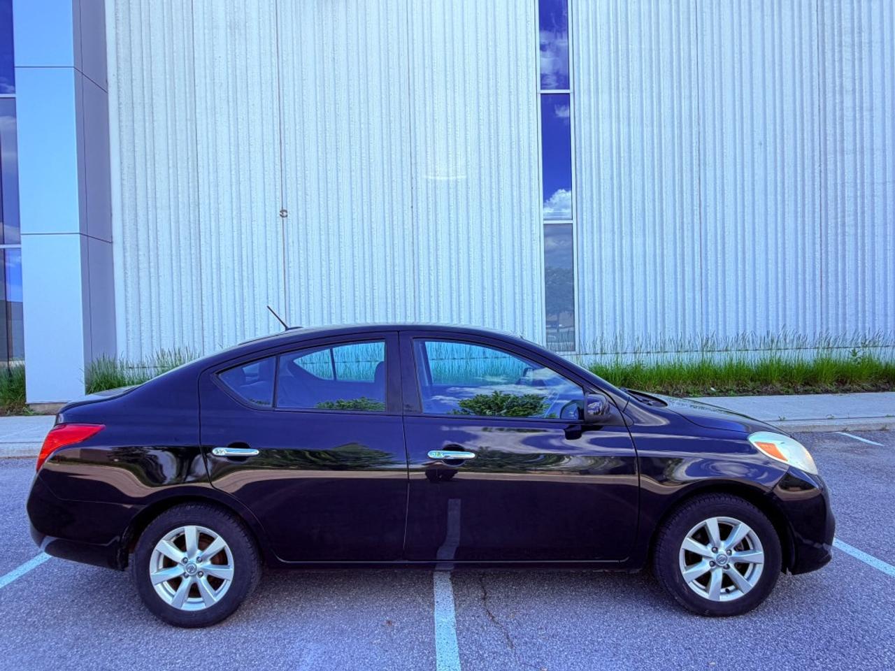 2012 Nissan Versa 1.6 S 4dr Sedan (1.6L 4cyl 5M) Photo