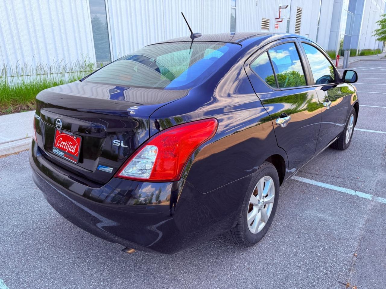 2012 Nissan Versa 1.6 S 4dr Sedan (1.6L 4cyl 5M) Photo