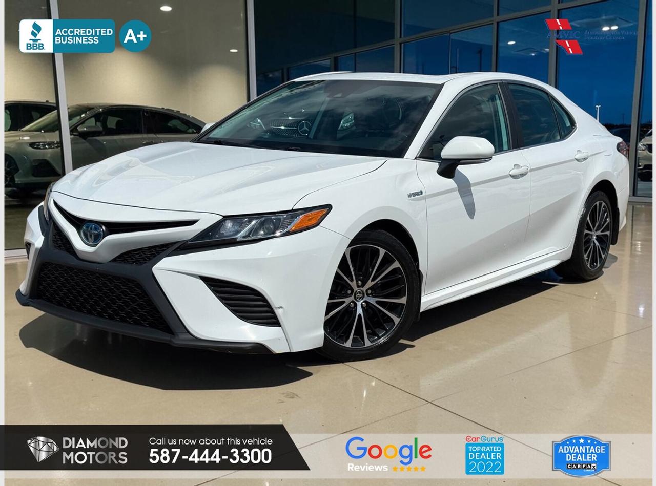 LIMITED TIME at Diamond Motors <br/> Drive away with a FREE 1-Year Warranty + low payments included at Listed Price. T&Cs Apply. <br/> <br/> <br/> Now Available: 2019 Toyota Camry Hybrid SE White has 196,701 KM on it. 2.5L 4 Cylinder Engine engine, Front-Wheel Drive, Automatic transmission, 5 Seater passengers, on special price for $23,900.00. <br/> <br/> <br/> ONE OWNER, NO ACCIDENTS, LEATHER, HEATED SEATS, LANE ASSIST, ADAPTIVE CRUISE CONTROL, BLUETOOTH, BACKUP CAMERA, BLIND SPOT MONITORING, SUNROOF, KEYLESS ENTRY, PUSH START, POWER SEATS, DUAL CLIMATE CONTROL, WIRELESS CHARGER AND MUCH MORE!!!!! <br/> <br/> <br/> Book your appointment today for Test Drive. We offer contactless Test drives & Virtual Walkarounds. Stock Number: 261115 <br/> Disclosure: This vehicle was previously registered in BC. Vehicle has passed all required inspections in Alberta. <br/> At Diamond Motors, we are dedicated to providing you with an outstanding car-buying experience, offering quality pre-owned vehicles at prices that fit your budget. Our transparent and honest approach means you can expect straightforward guidance without any high-pressure sales tactics. We believe in building lasting relationships with our customers by offering personalized service tailored to your needs. From the moment you step onto our lot, our team is here to support you every step of the way, ensuring you leave confident in your decision. Trust, integrity, and customer satisfaction are the foundation of everything we do. <br/> <br/> <br/> Why Choose Diamond Motors?<br/> <br/> Certified Pre-Owned Vehicles <br/> Family Owned & Operated <br/> 100+ Vehicles in Stock <br/> Finance & Extended Warranty Available <br/> Transparent Pricing <br/> Inspection & Carfax Provided <br/> No-Pressure Buying Experience <br/> Full Disclosure Guaranteed <br/> Top Google Rated Dealership <br/> Trade-Ins Welcome <br/> AMVIC Licensed & BBB Accredited <br/> CarGurus Top-Rated Dealer (2022 & 2024) <br/> <br/> <br/> Phone to schedule an appointment @ 587-444-3300 or simply browse our inventory online www.diamondmotors.ca or come and see us at our location at <br/> 3403 93 street NW, Edmonton, T6E 6A4 <br/> <br/> <br/> To view the rest of our inventory: <br/> www.diamondmotors.ca/inventory <br/> <br/> <br/> This dealership provides all required disclosures in accordance with AMVIC regulations. A completed Mechanical Fitness Assessment and its associated inspection work order will be supplied with every vehicle. A Carfax (or equivalent) vehicle history report will also be provided, including available information on previous damage, accident history, stolen or salvage status, and jurisdictional records. <br/> Customers are encouraged to review all vehicle features, options, and equipment for accuracy prior to purchase. <br/>
