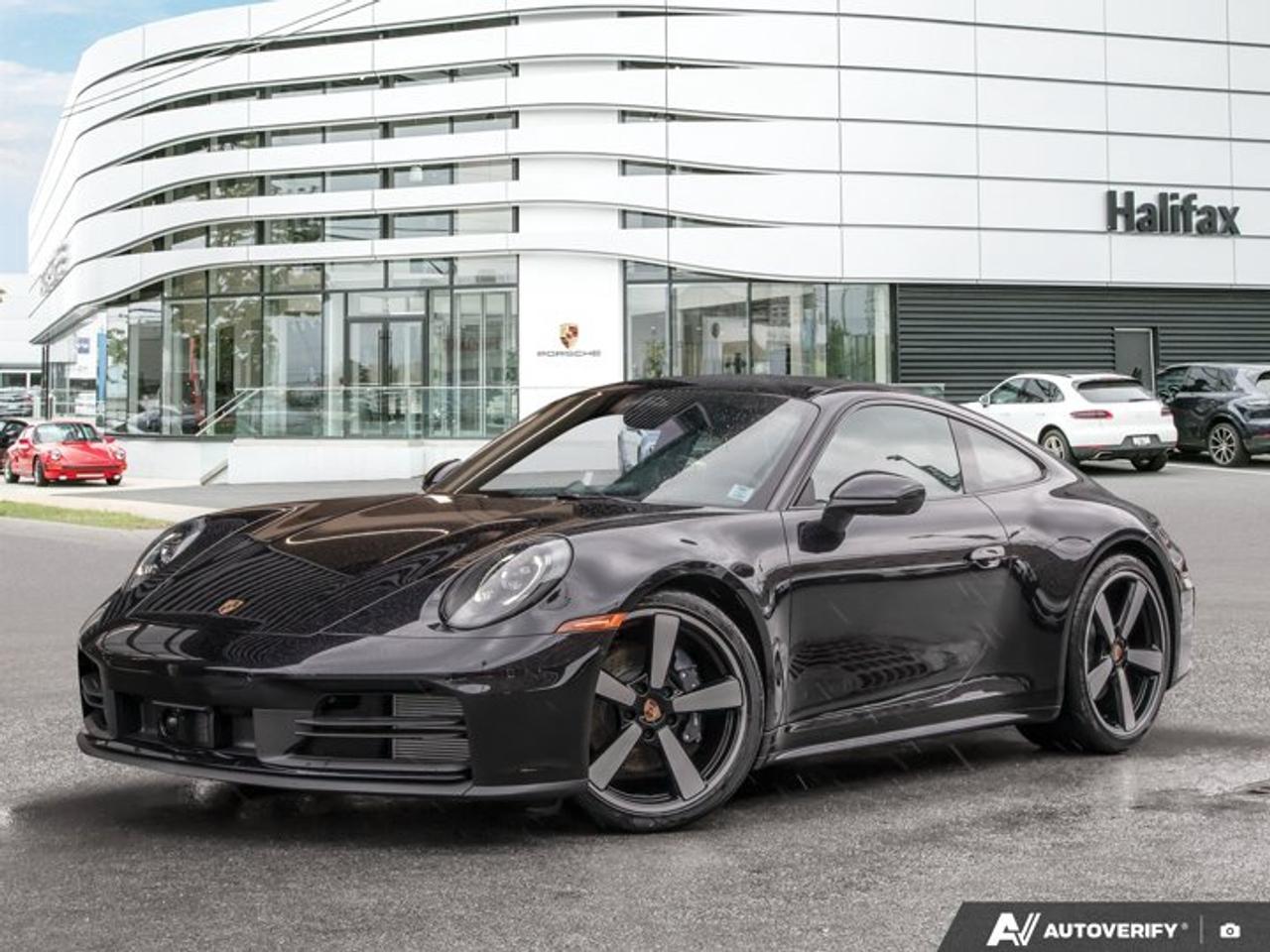 This 2026 Porsche 911 Carrera, now available at Porsche Of Halifax, is finished in Jet Black Metallic with a Leather Interior in Black/Bordeaux Red and is equipped with a PDK transmission.Powertrain and Drivetrain3.0-litre twin-turbocharged flat-6 engine producing 388 horsepower and 331 lb-ft of torquePDK transmissionRear-wheel driveExteriorJet Black MetallicElectric slide/tilt sunroof in glassSportDesign side skirtsPORSCHE logo on rear in High Gloss Black911 logo on rear in High Gloss BlackWindow trim in High Gloss Black20/21 Carrera Classic WheelsExclusive Design taillightsWheel center caps with colored Porsche CrestInterior and SeatingLeather Interior in Black/Bordeaux RedAdaptive Sport Seats Plus (18-way) with Memory PackageVentilated Seats (Front)Heated GT Sport Steering Wheel in LeatherPorsche Crest on Headrests (Front)Sport Chrono stopwatch and digital tachometer in WhiteRear seatsIonizerStorage net in passenger footwellTechnology and Driver AssistanceBOSE® Surround Sound SystemRemote ParkAssistLane Change Assist (LCA)Adaptive Cruise Control (ACC)Sport Chrono PackagePower Steering PlusExtended range fuel tank (22.1 gallons)Smoking packageThis 911 Carrera is configured with a twin-turbocharged rear-wheel-drive powertrain, a balance of performance and comfort features, and advanced driver assistance systems.Visit www.porscheofhalifax.com or call (902)453-8800 to speak with a Porsche Sales Executive.