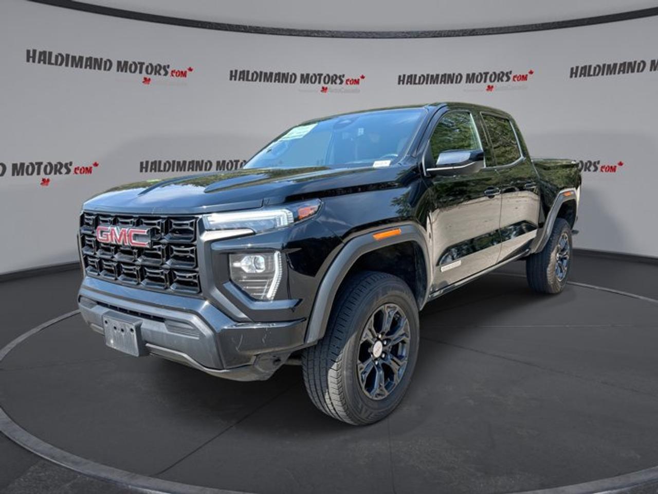 // ACCIDENT FREE!! //<br /><br />Meet the 2023 GMC Canyon Elevation Crew Cab 5 Box 4WD, a smart midsize truck built for hard work and easy daily driving. This used GMC comes finished in Black with a Black interior, four doors, automatic transmission, and a 2.7-litre gas engine. It has travelled 98,685 km and offers the confidence of a clean accident-free history.<br /><br />This 2023 GMC Canyon Elevation Crew Cab 5 Box 4WD blends pickup strength with modern comfort in a size that fits well in town, on the highway, and at the jobsite. With four-wheel drive, off-road tires, a backup camera, and a strong 3,492 kg towing capacity, it is ready for work, weekend travel, and changing Ontario weather.<br /><br />FEATURES OF THE Canyon Elevation Crew Cab 5 Box 4WD | No Accidents<br /><br />   Black exterior with matching Black cabin<br />   2.7-litre gas engine with automatic transmission<br />   Four-wheel drive for added traction<br />   Crew Cab with 5-foot box<br /><br />TRUCK FEATURES<br /><br />   Tows up to 3,492 kg confidently<br />   Rear tow hook supports truck utility<br />   Off-road tires add extra grip<br />   Crew Cab adds passenger versatility<br /><br />ADVANCED SAFETY FEATURES<br /><br />   Backup camera helps with safer reversing<br />   Lane departure warning adds awareness<br />   Anti-lock braking system supports control<br />   Stability control improves road confidence<br /><br />PERFORMANCE AND EFFICIENCY<br /><br />   2.7-litre gas engine delivers solid power<br />   Eight-speed automatic supports smooth shifting<br />   Four-wheel drive handles changing conditions<br />   Power steering helps easy daily driving<br /><br />COMFORT AND CONVENIENCE<br /><br />   Front air conditioning keeps cabin comfortable<br />   Cruise control supports relaxed highway travel<br />   Power windows add daily convenience<br />   Adjustable steering wheel improves driving position<br /><br />TECHNONOLGY AND CONNECTIVITY<br /><br />   Apple CarPlay connects your favourite apps<br />   Android Auto adds simple smartphone access<br />   Bluetooth integration supports hands-free calling<br />   WiFi hotspot keeps devices connected<br /><br />CARGO SPACE<br /><br />   5-foot box suits daily hauling needs<br />   Rear trunk access supports easy loading<br />   Spare tire adds practical peace of mind<br />   Four-door layout helps carry gear inside<br /><br />AWARDS & RECOGNITIONS<br /><br />   Best Buy Award, The Car Guide, 2023<br />   Editors Choice, AutoTrader Canada, 2023<br /><br />WHAT OTHER OWNERS LIKE<br /><br />   Strong towing ability for midsize truck<br />   Easy-to-use technology and phone connectivity<br />   Comfortable ride for daily commuting<br />   Useful size for work and play<br /><br />This GMC Canyon is equipped with the features drivers want most for real-world use. Cruise control, power steering, power windows, electric mirrors, tinted windows, and automatic door locks help make every trip simple. Push button start adds a modern touch, while steering wheel audio controls keep key functions close at hand.<br /><br />Safety and visibility are well covered in this GMC. It includes driver and passenger airbags, side impact airbags, head side airbags, a passenger airbag sensor, tire pressure monitoring, automatic headlights, and LED headlamps. These features help support confidence on busy streets, dark roads, and long highway drives.<br /><br />Inside, the cabin is set up for comfort and practical use. Front air conditioning, illuminated driver and passenger vanity mirrors, and a roomy Crew Cab layout make this truck easy to live with every day. The black-on-black colour combination gives it a clean, professional look that suits both business and personal use.<br /><br />Entertainment and connectivity are also strong points. Satellite radio, Bluetooth integration, Apple CarPlay, Android Auto, and a WiFi hotspot help keep everyone connected and entertained. Whether you are heading to work, towing equipment, or planning a weekend away, this GMC Canyon offers the right mix of capability and modern function.<br /><br />For drivers shopping at Haldimand Motors Ltd. in Cayuga, this accident-free 2023 GMC Canyon Elevation Crew Cab 5 Box 4WD stands out as a capable and well-equipped truck. It delivers useful towing strength, practical four-wheel drive traction, and the everyday features that matter most in a dependable used pickup.<br /><br />This 2023 GMC Canyon Elevation Crew Cab 5 Box 4WD | No Accidents Useds VIN is: 1GTP6BEK2P1183215.<br /><br />WHY CHOOSE US? <br /><br />Honest & Transparent Buying Experience: Weve been a trusted name in business since 1984.<br /><br />STRAIGHTFORWARD PRICING:<br />Our Advertised Price Includes:<br />>>Safety Certification (No separate fee!)<br />>>30-Day 100% Mechanical Warranty<br />>>FREE Carfax History Report.<br />>>No upcharge for paying cash.<br />(Prices Exclude HST and Licensing Fees only.)<br /><br />>>Browse 300+ vehicles all in ONE LOCATION<br /><br />EASY FINANCING: Great rates & open loans<br /><br />WE BUY CARS: Get Top Dollar for your trade-in, or sell us your vehicle for CASH! Even if you dont buy from us!<br /><br />STOP BY TODAY<br />Treat yourself - stop by Haldimand Motors Ltd. located at 42 Talbot St E, Cayuga, ON N0A 1E0 to make this car yours today!<br /><br />https://www.haldimandmotors.com/used/stock-460829.html