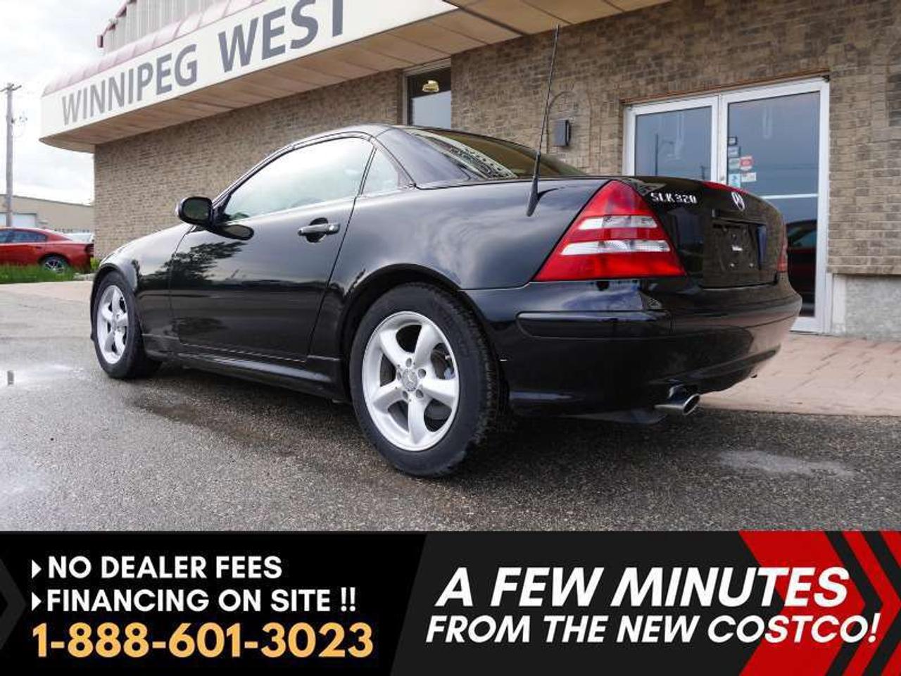 *** Dealer arranged financing on site! Quick, Simple,  no calls or waiting on bank appointments required!! Drive away today ***   NO ADMINISTRATION FEES!!

2004 Mercedes-Benz SLK320 RWD - - Classic retractable hardtop roadster - - Signature Vario-Roof  - - 5-speed automatic Mercedes-Benz 5G-Tronic - - 3.2-liter V6 engine - - Standard side airbags - - Leather heated seats - - Dual-zone climate control - - Bluetooth AM/FM Radio - - Sirius XM Ready - - 6-disc CD changer - - Custom-tuned Bose premium audio system - - 8-way power-adjustable sport seats - - Leather steering wheel - - Wood-grain accents - - 16-inch alloy wheels - - Steel polished exhaust tips - - Power windows - - Power doors.

Sharp in  classic Gloss Black. Matching black interior with heated bucket leather seats, leather wrapped steering wheel with wood grain accents.  Premium sound system is tailored specifically to the SLKs cabin acoustics, designed to maintain audio quality with the hardtop up or down......... speed-sensitive volume, adjusting automatically as you drive.

R170 generation with classic styling and balanced handling. A roadster with great history. Excellent service records. This car is a Gem!!  

Features
- 3.2-liter V6 engine 
- 215 horsepower and 229 lb-ft of torque
- 5-speed TouchShift automatic
- Signature Vario-Roof 
- Standard side airbags
- Leather heated seats 
- Dual-zone climate control 
- Bluetooth CD/AM/FM Radio 
- Sirius XM Ready -
- 6-disc CD changer 
- Bose premium audio system
- 8-way power-adjustable sport seats 
- Wood-grain accents 
- 16-inch alloy wheels
- All season tires
- Steel polished exhaust tip
- Power windows
- Power doors
- Power mirrors
- Integrated turn signals
- Fog lights
- Heated headlamp washers
- Tilt-and-telescoping steering wheel
- Auto-dimming rearview mirror 
- Electronic Stability Program (ESP)
- Anti-lock brakes (ABS)

Comes with a Manitoba Safety Certification, and we have many Extended Powertrain warranties available on your vehicle purchase up to 10-year coverage (on eligible vehicles see dealer for details). Financing on site with Zero down financing OAC. Trades accepted. View at Winnipeg West Automotive Group, 5195 Portage Ave. (only a couple of minutes past the new Costco) Dealer permit # 6007, Call now 1(888) 6O1-3O23. This Car is located in Winnipeg Manitoba,  however we can have it shipped anywhere in North America relatively inexpensively.
