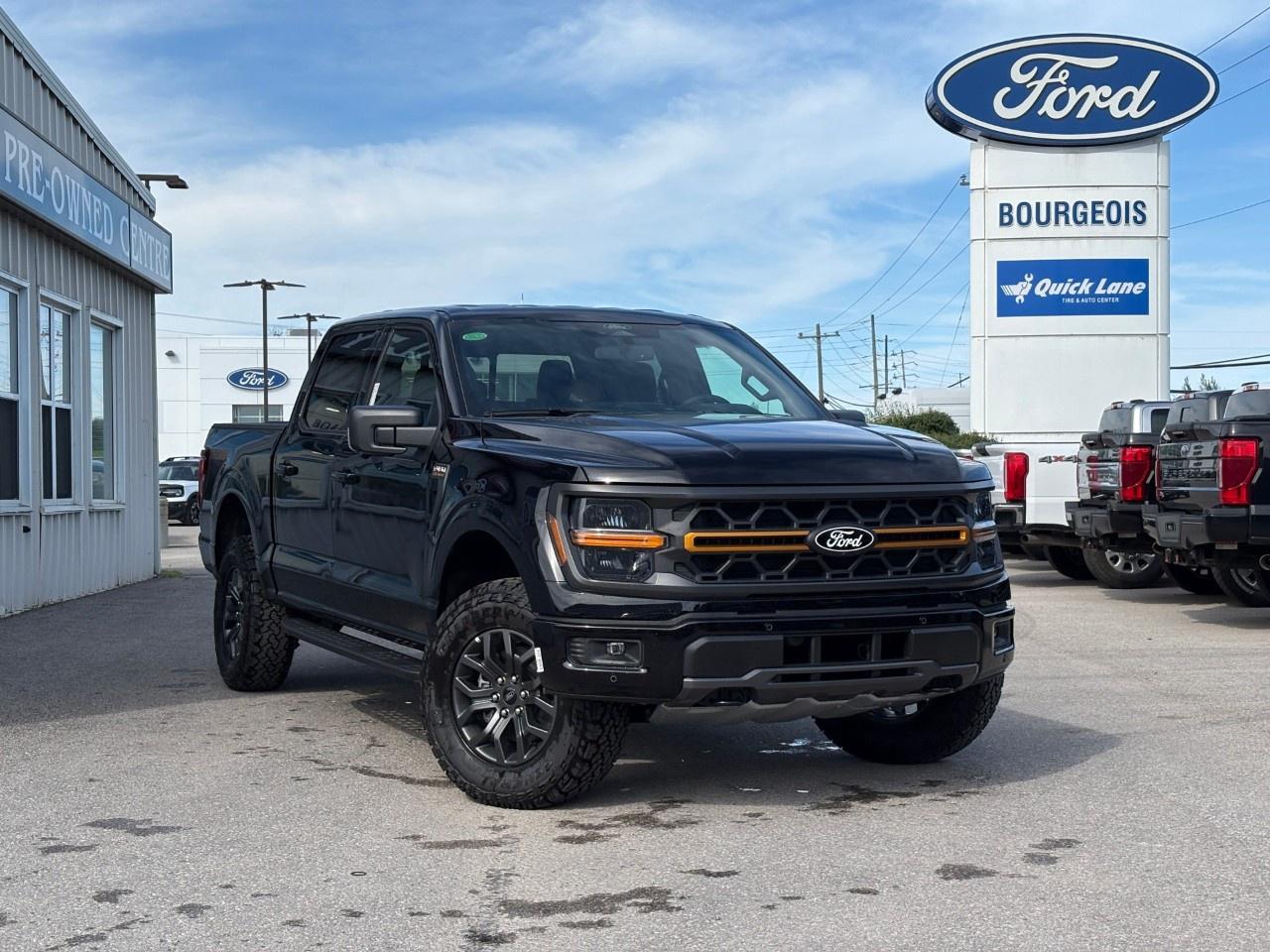 <p>The 2026 Ford F-150 Tremor 4WD SuperCrew 5.5' Box in striking Agate Black Metallic offers robust 4×4 capabilities ready to tackle any terrain. With its exceptional handling characteristics, this truck is engineered for those who crave adventure.</p><p>Characterized by a rugged black exterior and a commanding presence, the F-150 Tremor is built to make a statement. The interior features a black cabin that is both spacious and refined, complete with heated leatherette seats and a leatherette steering wheel for a luxurious touch. Additionally, the Tough Bed Spray-In Bedliner adds practical ruggedness, perfect for handling any cargo.</p><p>This F-150 is equipped with cutting-edge technology like a navigation system, backup camera, and smart device integration, ensuring you stay connected and informed wherever you go. It also includes convenience features such as power windows, remote start, and a driver's side SecuriCode Keyless-Entry Keypad for seamless access. Safety is paramount with advanced features like lane assist, parking sensors, and adaptive cruise control, all designed to keep you secure on the road.</p><p>With a potent 5.0L V8 engine, an electronic 10-speed automatic transmission with various selectable drive modes, and an integrated trailer brake controller, this truck is perfect for those who need both power and versatility. Whether youre towing a trailer or driving through challenging conditions, this vehicle is prepared for anything.</p><p>Are you someone who values capability and innovation in your vehicle? Dont miss your chance to own this incredible truck. Contact Bourgeois Motors Ltd. today to learn more about the 2026 Ford F-150 Tremor and arrange your test drive.</p> <p><span style=color:rgb( 58 , 80 , 95 )>The discount shown on vehicle represents the </span><u>Cash Purchase</u><span style=color:rgb( 58 , 80 , 95 )> discount and is inclusive of all non-stackable and stackable cash purchase discounts from Ford of Canada and Bourgeois Motors Ltd. and is offered in lieu of sub-vented lease or finance rates. To get details on current discounts applicable to this and other vehicles in our inventory for Lease and Finance customer, see a member of our team. All offers for lease or finance are On Approved Credit (OAC).While every effort is made to ensure the accuracy of discounts and programs, programs are subject to change without notice </span><span style=color:rgb( 119 , 119 , 119 )>and may not be accurate or completely current. While every reasonable effort is made to ensure the accuracy of this data, we are not responsible for any errors or omissions contained on these pages.</span></p> <p><strong>Why Choose the Bourgeois Auto Group?</strong></p><p>For 80 years, Bourgeois Auto Group has been delivering exceptional automotive experiences. Our factor trained teams work to ensure you receive the shopping experience you deserve; whether you're looking for a new or new-to-you vehicle.</p><p>Shop 24/7 with our online showroom and chat service, ensuring convenience every step of the way. No hidden fees, full disclosure, and every pre-owned vehicle comes with a Carfax® report for peace of mind.</p><p>We offer a wide selection of pre-owned vehicles, all competitively priced using real-time market data. Get the best deal on your purchase and trade-in with our free Live Market Analysis report.</p><p>Looking to sell your car? We buy any make or modelno purchase required. Our simple to use online trade valuation tool will provide you with a clear, transparent selling experience whether you buy our car or not.</p><p>Backed by hundreds dedicated employees across 4 convenient locations, were here to meet all your automotive needs. Visit us in Midland or Parry Sound and explore our inventory or schedule your next service today.</p> <p><strong>Financing Your Next Vehicle with Bourgeois Motors Ford in Midland:</strong></p><p>At Bourgeois Motors Ford, we make financing your next vehicle simple and stress-free! Our team works with trusted lenders to find flexible options tailored to your budget. Drive away with confidenceapply today!</p><p>Take advantage of our online pre-qualification tool, backed by Equifax and TD Bank to find the payment that works for you. Simply <a href=https://www.bourgeoismotors.com/free-credit-check/ rel=nofollow><strong>CLICK HERE</strong></a><strong> </strong>to use our secure online credit tool with no impact to your credit.</p>