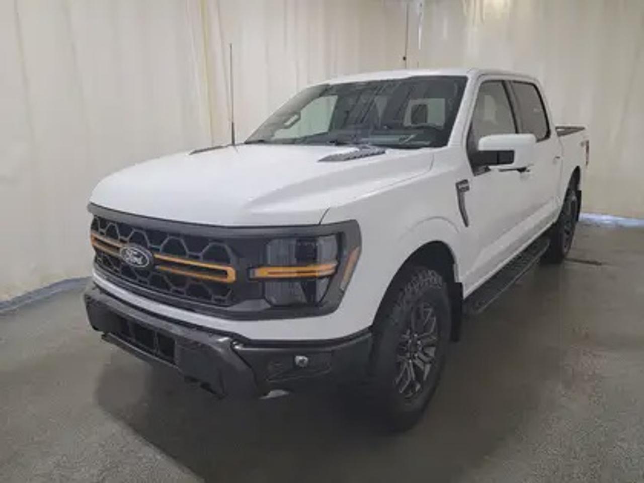 The all-new 2025 Ford F-150 Tremor 402A showcased in Oxford White. This truck is equipped with the high-performance 3.5L EcoBoost engine, producing 400 horsepower and 500 lb-ft of torque. With its 10-speed automatic transmission, also delivering a combined highway/city fuel economy of 12.9L/100km (22 miles per gallon). 

Key Features:
Bed Utility Package
Mobile Office Package
Tow/Haul Package
Front Axle W/Torsen Differential
Selectable Drive Modes
18 Alloy W/ Dark Matte Finish Wheels
Heated Front Seats & Rear Seats
Ford Co-Pilot 360 Assist 2.0
Adaptive Cruise Control
Lane Centering
Evasive Steering Assist
Front Parking Sensors
Pro Trailer Backup Assist
Pro Trailer Hitch Assist
14 Speaker B&O Unleashed Sound System
Hill Descent Control
Remote Start System
Heads Up Display
Engine Block Heater
Twin Panel Moonroof

This vehicle comes with the All-Weather Packageready to take on any season! Snow, rain, mud, or sunshinethis vehicle is built for it all! The All-Weather Package adds extra protection where it matters most, with premium mud flaps to shield your paint from road debris, all-weather floor mats to protect your interior from lifes messes, and Xpel paint protection to help guard against those infuriating rock chips. Drive with confidence, knowing your investment is protected from Reginas elements.

Bennett Dunlop Ford, proudly serving Regina for over 40 years, is conveniently located at 770 Broad Street. With over 3,500 Google reviews, our reputation reflects our commitment to providing a fast, easy, and enjoyable vehicle-buying experience. We eliminate the hassle with no admin or documentation fees, transparent upfront pricing that lets you shop with total confidence. But were more than just a dealershipwere driven to make a difference by supporting local community initiatives and events that matter to you. Visit Bennett Dunlop Ford today and experience why were Reginas trusted choice for quality vehicles, exceptional service, and a genuine commitment to driving change in our community!