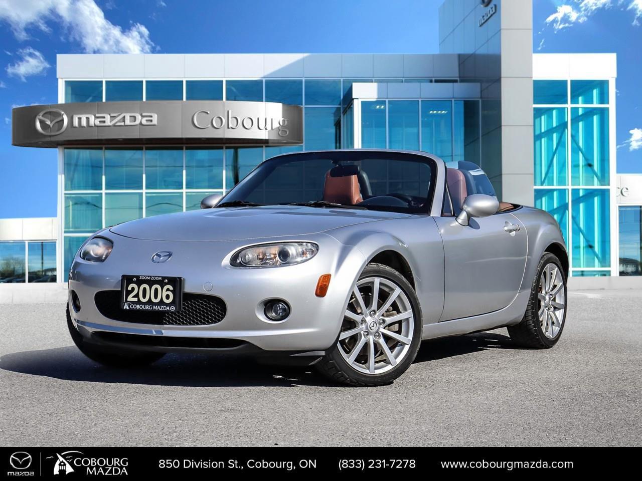 <p>Introducing the charming 2006 Mazda MX-5 GT, a beautifully presented silver convertible with rear-wheel drive and automatic transmission, designed to offer exceptional handling and a thrilling drive.</p> <p>The exterior of this MX-5 GT gleams in silver, perfectly complemented by sleek alloy wheels that underline its sporty styling. Step inside to find a luxurious tan interior adorned with premium leather seats, providing both comfort and elegance. The attention to detail extends with features like heated seats and keyless entry, making every journey a pleasure.</p> <p>Equipped with modern conveniences such as air conditioning and power windows, this MX-5 GT brings comfort to every drive. It also boasts cruise control for those longer trips. These features ensure that you are always connected and at ease, allowing you to focus on the joy of the open road and the thrill of top-down driving.</p> <p>If youre someone who values style and an engaging driving experience, this Mazda MX-5 GT is perfect for you. Don't miss the opportunity to own this classic convertible. Contact Cobourg Mazda for more details and take the first step towards open-air adventures.</p>