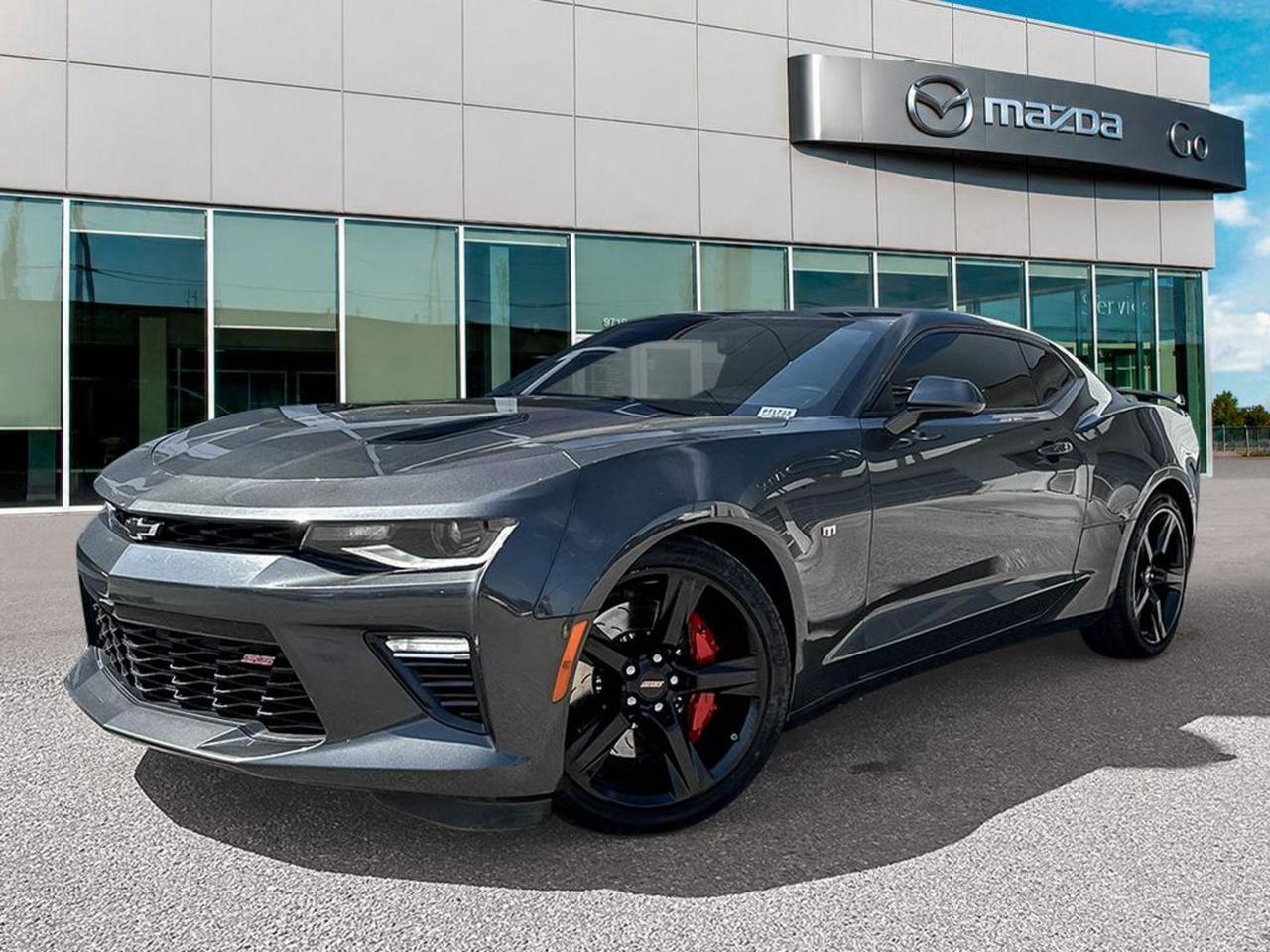 Experience pure muscle and style with this pre-owned 2017 Chevrolet Camaro 2SS Coupe in sleek Black. Powered by a thrilling 6.2L V8 engine paired with a 6-speed manual transmission, this Camaro delivers an exhilarating driving experience. Equipped with premium 20 aluminum wheels wrapped in run-flat tires, sport-tuned suspension, and a mechanical limited-slip differential, its built for performance and precision.Inside, enjoy luxurious leather-trimmed sport bucket seats with heated and ventilated front seating, dual-zone automatic climate control, and advanced tech including Chevrolet MyLink, Bose premium 9-speaker audio, SiriusXM, and a touchscreen with navigation. Safety features like blind-spot warning, rear parking sensors, and a rearview camera keep you confident on every drive.This Camaro 2SS perfectly blends iconic muscle car power with modern comfort and technology  a true drivers dream. Dont miss your chance to own a legendary classic with all the benefits of updated features. Contact us today to take it for a spin!