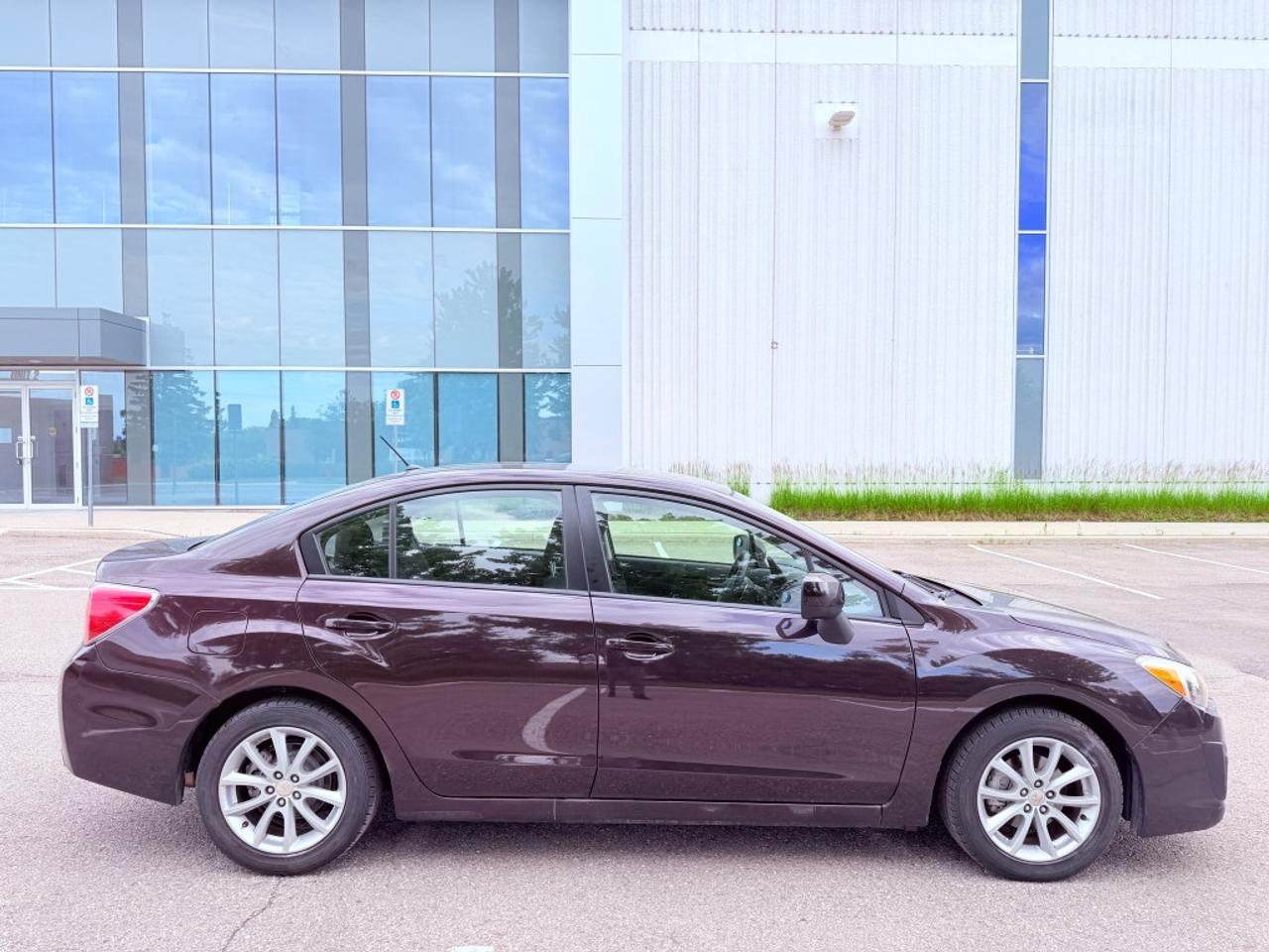 2012 Subaru Impreza 2.0i Premium 4dr Sedan AWD (2.0L 4cyl CVT) Photo