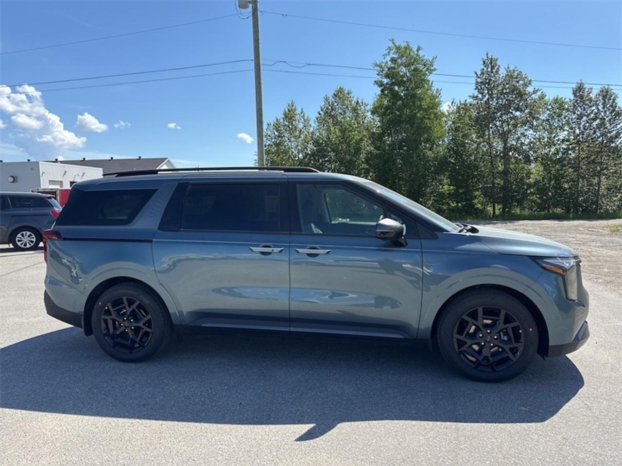 2026 Kia Carnival SX+  Harman/Kardon Premium Audio - $402 B/W Photo1