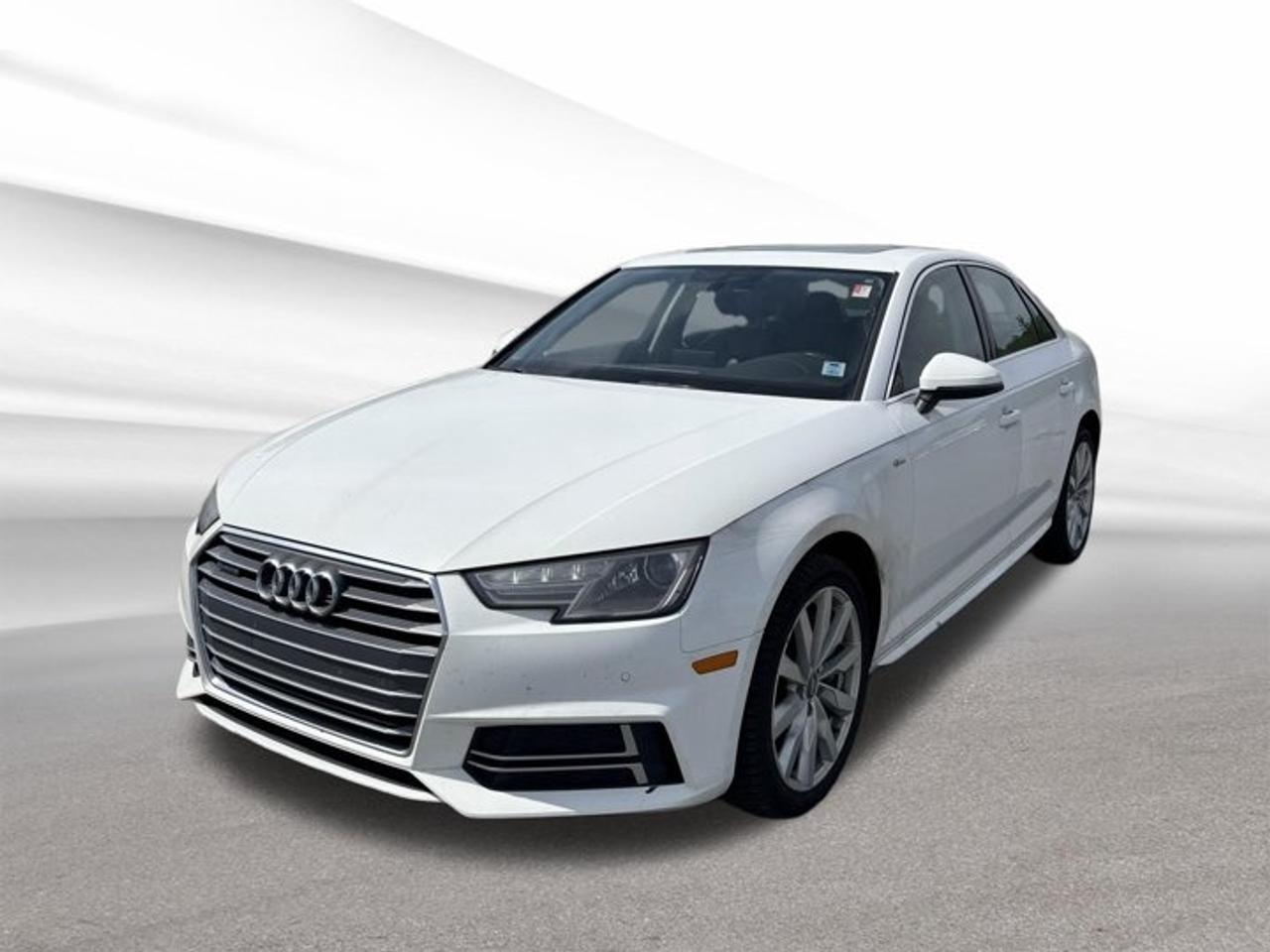 The 2018 Audi A4 Komfort is a refined used sedan that blends premium comfort, confident all-weather capability, and efficient turbocharged performance. Offered by Steele Halifax Chrysler Dodge Jeep Ram FIAT in Halifax, this four-door model features Audi all-wheel drive, an automatic transmission, and a 2.0-litre intercooled turbocharged gas engine. With 140,780 km, this A4 Komfort remains a strong choice for drivers who want upscale design, composed road manners, and everyday practicality in one well-balanced package.FEATURES OF THE A4 KomfortStandard Audi all-wheel drive confidenceTurbocharged 2.0-litre four-cylinder performanceRefined cabin with premium designSmooth automatic transmission for commutingADVANCED SAFETY FEATURESElectronic stability control for added confidenceAdvanced airbag system for occupant protectionFour-wheel anti-lock braking for controlRearview camera support on many modelsPERFORMANCE AND EFFICIENCY2.0-litre turbo engine delivers responsive powerAutomatic transmission shifts smoothly and efficientlyAll-wheel drive boosts year-round tractionBalanced ride suits city highway drivingCOMFORT AND CONVENIENCEFour-door layout improves daily usabilityDual-zone climate control enhances comfortSpacious cabin supports relaxed commutingQuiet ride adds long-trip comfortTECHNOLOGY AND CONNECTIVITYClear infotainment interface feels intuitiveBluetooth connectivity supports hands-free callingDriver information display keeps essentials visibleConvenient audio controls aid easy accessCARGO SPACERear trunk handles daily gear easilySplit-folding rear seat adds versatilitySedan design keeps cargo secureWide opening helps loading convenienceAWARDS & RECOGNITIONSTop Safety Pick, Insurance Institute for Highway Safety, 2018Best Buy winner, The Car Guide, 2018WHAT OTHER OWNERS LIKEConfident all-wheel drive in poor weatherSmooth turbo power for daily drivingQuiet cabin with upscale feelSolid handling with comfortable rideThe 2018 Audi A4 Komfort delivers the kind of driving experience that feels polished from the first kilometre. Its turbocharged engine offers a satisfying mix of power and efficiency, while the automatic transmission keeps acceleration smooth in traffic and on the highway. Audi all-wheel drive adds valuable confidence during Halifax winters and wet road conditions.Inside, the 2018 Audi A4 Komfort is designed with a clean, modern layout that supports both comfort and focus. The four-door body style makes access easy for passengers, while the trunk offers practical room for groceries, work gear, or weekend bags. This sedan suits drivers who want premium character without giving up usefulness.For shoppers seeking a used luxury sedan with proven appeal, the 2018 Audi A4 Komfort stands out with its composed handling, quality engineering, and timeless styling. It is a smart fit for commuting, family use, or long-distance travel, delivering a premium feel in a practical package from Steele Halifax Chrysler Dodge Jeep Ram FIAT in Halifax.This 2018 Audi A4 Komforts VIN is: WAUANAF47JN005266 .We invite you to book a viewing and test drive at your earliest convenience
