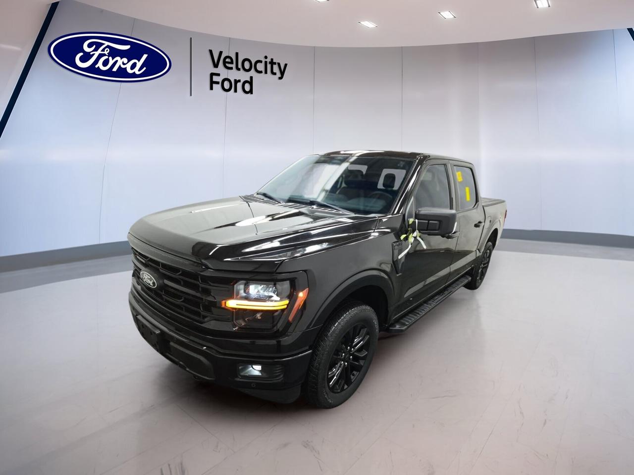 // SINGLE OWNER! //

Meet this 2024 Ford F-150 XLT 4WD SuperCrew 5.5 Box, now available at Velocity Ford in Moose Jaw. CARFAX Canada reports a single owner, and the odometer shows just 22,624 km. Finished in Black with four doors, automatic transmission, and a 3.5-litre unleaded engine, this truck blends everyday comfort with strong capability.

Built for work, travel, and family duty, this used Ford F-150 XLT 4WD SuperCrew 5.5 Box offers the versatility buyers want in a full-size pickup. Its roomy cab, practical 5.5-foot box, and four-wheel drive setup help it handle changing road and weather conditions across Saskatchewan with confidence.

FEATURES OF THE F-150 XLT 4WD SuperCrew 5.5 Box
»» Black exterior with bold road presence
»» Four-door SuperCrew cabin adds easy access
»» Automatic transmission for smooth daily driving
»» 3.5-litre unleaded engine delivers strong power

TRUCK FEATURES
»» Towing capacity rated at 4,671 kg
»» Four-wheel drive adds extra traction
»» Rear tow hook supports truck utility
»» Side steps help cabin entry

ADVANCED SAFETY FEATURES
»» Backup camera helps with reversing visibility
»» Blind spot monitor adds lane awareness
»» Lane departure warning supports safer travel
»» Side curtain airbags enhance occupant protection

PERFORMANCE AND EFFICIENCY
»» 3.5-litre engine balances power and response
»» Automatic transmission shifts smoothly in traffic
»» Four-wheel drive improves slippery-road confidence
»» Stability control helps maintain composed handling

COMFORT AND CONVENIENCE
»» Dual-zone climate control improves cabin comfort
»» Driver power seat supports easy adjustment
»» Passenger lumbar support adds ride comfort
»» Cruise control helps on longer highway trips

TECHNOLOGY AND CONNECTIVITY
»» Navigation system helps guide each trip
»» Bluetooth integration supports hands-free communication
»» WiFi hotspot keeps devices better connected
»» Steering wheel audio controls add convenience

CARGO SPACE
»» 5.5-foot box handles daily hauling needs
»» Rear trunk access supports loading convenience
»» Spare tire adds peace of mind
»» SuperCrew cabin offers extra interior storage

AWARDS & RECOGNITIONS
»» North American Truck of the Year, North American Car, Utility and Truck of the Year, 2024

WHAT OTHER OWNERS LIKE
»» Strong towing ability for work and play
»» Spacious cabin for family and gear
»» User-friendly tech for everyday driving
»» Confident ride in mixed road conditions

This truck also includes useful features that make daily ownership easier. You get power steering, anti-lock braking system, heated mirrors, power windows, automatic headlights, fog lights, tinted windows, tire pressure monitoring, satellite radio, and chrome wheels. LED headlamps add clear lighting and a modern look.

Inside, this pickup is set up for comfort and simple operation. Front air conditioning, automatic climate control, an adjustable steering wheel, illuminated vanity mirrors, and cloth seating help create a practical cabin. Safety features such as child safety locks, driver and passenger airbags, and a passenger airbag sensor add extra reassurance.

If you need a capable full-size pickup with strong towing, smart tech, and proven day-to-day usability, this 2024 Ford F-150 XLT 4WD SuperCrew 5.5 Box is ready to deliver. Visit Velocity Ford in Moose Jaw to see how well this single-owner truck fits your work and lifestyle needs.

This 2024 Ford F-150 XLT 4WD SuperCrew 5.5 Boxs VIN is: 1FTFW3L88RFA36007.