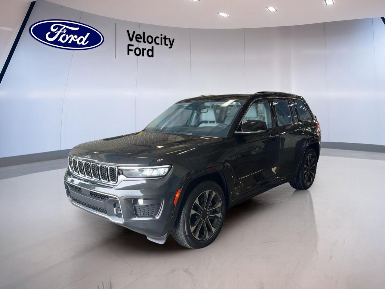 Meet a refined and capable SUV built for Canadian roads. This used 2023 Jeep Grand Cherokee Overland 4x4 at Velocity Ford in Moose Jaw pairs Rocky Mountain Pearl paint with a Black interior for a clean, upscale look. With 59,200 km, a 3.6 L unleaded engine, automatic transmission, and four-door practicality, this Grand Cherokee Overland 4x4 delivers comfort, confidence, and everyday versatility.

FEATURES OF THE Grand Cherokee Overland 4x4

»» Panoramic sunroof brightens every drive beautifully
»» Air suspension adds comfort and control
»» Power liftgate helps with daily loading
»» Heated front and rear seats included

ADVANCED SAFETY FEATURES

»» Backup camera helps with tight parking
»» Blind spot monitor adds lane-change confidence
»» Lane departure warning supports safer travel
»» Side and head airbags enhance protection

PERFORMANCE AND EFFICIENCY

»» 3.6 L engine delivers smooth power
»» Eight-speed automatic supports relaxed highway cruising
»» Four-wheel drive adds all-season traction
»» Limited slip differential improves grip control

COMFORT AND CONVENIENCE

»» Dual-zone climate control keeps comfort balanced
»» Memory seats simplify shared driving routines
»» Remote starter adds cold-weather convenience
»» Heated mirrors help clear winter frost

TECHNOLOGY AND CONNECTIVITY

»» Navigation system helps guide every trip
»» Bluetooth integration supports hands-free calling
»» WiFi hotspot keeps passengers better connected
»» Steering wheel audio controls add ease

CARGO SPACE

»» Rear trunk access makes loading simple
»» Power liftgate adds everyday convenience
»» Four-door layout supports family practicality
»» Spare tire adds peace of mind

WHAT OTHER OWNERS LIKE

»» Smooth ride quality on long trips
»» Comfortable cabin with upscale road feel
»» Confident winter traction from four-wheel drive
»» User-friendly technology for daily driving

This 2023 Jeep Grand Cherokee Overland 4x4 brings together premium comfort and real utility in one well-equipped package. The Rocky Mountain Pearl exterior gives it a polished finish, while the panoramic sunroof and glass roof create an open, airy feel inside. Its design suits family travel, commuting, and weekend escapes with equal ease.

This 2023 Jeep Grand Cherokee Overland 4x4 is powered by a proven 3.6 L unleaded engine matched to an 8-speed automatic transmission. That setup gives this SUV smooth acceleration, composed highway manners, and easy response in town. Four-wheel drive, adjustable suspension, and air suspension help this Grand Cherokee Overland 4x4 stay composed through changing road and weather conditions.

Inside, this 2023 Jeep Grand Cherokee Overland 4x4 focuses on comfort and convenience. Heated front and rear seats, automatic climate control, dual-zone settings, power seating, lumbar support, and memory functions help make every trip more relaxing. Push-button start, power windows, tinted windows, retractable mirrors, and automatic headlights add simple everyday ease.

This 2023 Jeep Grand Cherokee Overland 4x4 also offers smart tech for modern driving. Navigation, satellite radio, HD Radio, Bluetooth integration, WiFi hotspot capability, and a backup camera help keep you informed and connected. LED headlamps, fog lights, tire pressure monitoring, and a blind spot monitor support confidence behind the wheel.

For drivers in Moose Jaw looking for a used SUV with comfort, capability, and premium features, this 2023 Jeep Grand Cherokee Overland 4x4 stands out for all the right reasons.

This 2023 Jeep Grand Cherokee Overland 4x4s VIN is: 1C4RJHDTXP8712860 .