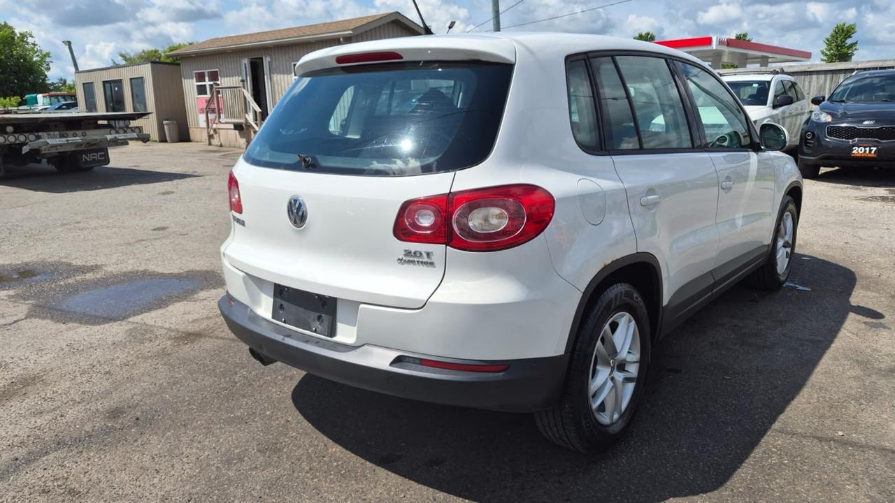2010 Volkswagen Tiguan TRENDLINE, AUTO, 4 CYL, 4WD, AS IS SPECIAL Photo