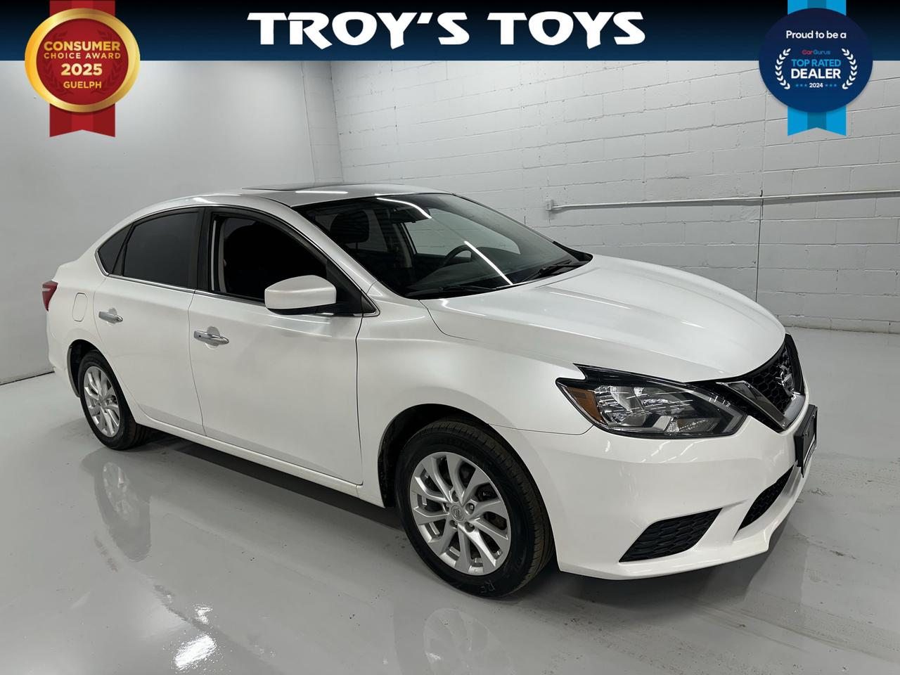 <p>Looking for a reliable and stylish sedan that wont break the bank? Troys Toys has just the thing for you with this sharp white 2017 Nissan Sentra S. This practical sedan boasts a sleek exterior and a comfortable black interior, perfect for your daily commute or weekend adventures. With a smooth automatic transmission and front-wheel drive, youll experience an easy and efficient ride, all while enjoying the fuel economy of a gasoline-powered engine. This four-door sedan offers ample space and convenience for passengers and cargo alike.</p><p>This particular Sentra S has seen 102,927 kilometers of reliable service, proving its enduring quality and dependability. At Troys Toys, we pride ourselves on offering quality pre-owned vehicles, and this Sentra is no exception. Its ready to be your trusted companion on the road, offering a blend of comfort, practicality, and a touch of sporty appeal. Come on down to Troys Toys and see why this Sentra S is such a smart choice.</p><p>Here are 5 sizzling features that make this 2017 Nissan Sentra S a standout:</p><ul><li><strong>Effortless Automatic Transmission:</strong> Glide through your gears with the smooth and responsive automatic transmission, making every drive a breeze.</li><li><strong>Sleek White Exterior:</strong> Turn heads with the classic and clean white exterior, exuding a timeless and sophisticated look.</li><li><strong>Comfortable Black Interior:</strong> Settle into the supportive and stylish black interior, designed for maximum comfort on any journey.</li><li><strong>Practical Four-Door Sedan Design:</strong> Enjoy easy access for all passengers and convenient cargo loading with the versatile four-door sedan configuration.</li><li><strong>Dependable Front-Wheel Drive:</strong> Experience confident handling and efficient performance on various road conditions thanks to the proven front-wheel drive system.</li></ul><p><strong><em>Powered by AutoIntelligence&trade;</em></strong></p><p>Vehicle information has been generated using artificial intelligence and is provided for informational purposes only. While efforts are made to ensure accuracy, please confirm all details directly with the dealer.</p>