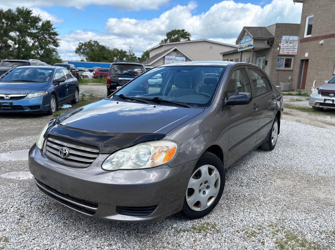 <p><p><strong>2003 Toyota Corolla  Safety Included | 1-Year Powertrain Warranty</strong></p><p>Reliable and fuel-efficient <strong>2003 Toyota Corolla</strong> with <strong>185,000 KM</strong>. Known for its durability and low cost of ownership, this Corolla is a great choice for commuting, students, or anyone looking for dependable transportation.</p><p>The vehicle comes <strong>Ontario safety certified and ready for the road</strong>, with a <strong>1-Year Powertrain Warranty included</strong>.</p><p> 185,000 KM<br> Safety certified<br> 1-Year Powertrain Warranty included<br> Excellent fuel economy</p><p><strong>Condition and driving</strong></p><p>Drives very smooth<br>Well maintained<br>Fully inspected and safety ready</p><p><strong>Why this Corolla</strong></p><p>Proven Toyota reliability<br>Very good on gas<br>Affordable to own and maintain<br>Practical and dependable daily driver</p><p><strong>Warranty</strong></p><p>1-Year Powertrain Warranty Included</p><p> Engine<br> Transmission<br> Differential</p><hr><p><strong>AUTO NATION CAR SALES & SERVICES</strong><br>9300 Tecumseh Rd. East, Windsor, ON N8R 1A2<br>Call or Text: 226-246-2429</p><p>We accept Debit / Visa / Mastercard / AMEX.<br>All-in pricing (plus HST & licensing only).</p><span id=jodit-selection_marker_1781817494439_5993449694071822 data-jodit-selection_marker=start style=line-height: 0; display: none;></span><br></p>