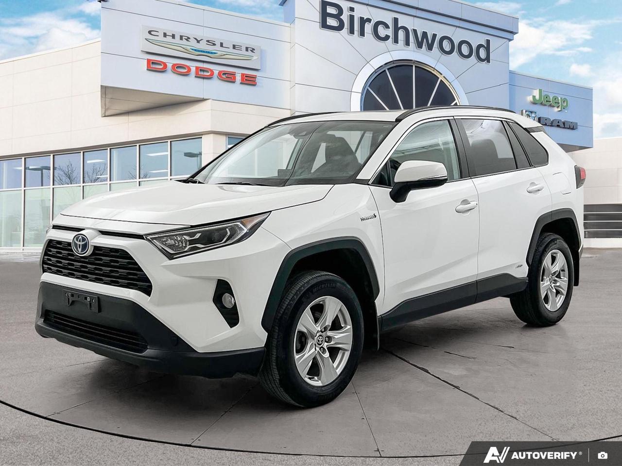 If youre looking for a fuel-efficient, tech-forward SUV that handles Manitoba winters with confidence, this 2021 Toyota RAV4 Hybrid XLE AWD delivers exactly that. With a hybrid powertrain offering impressive city and highway fuel economy, a clean accident-free history, and a long list of comfort and safety features, this RAV4 Hybrid is a smart, practical choice for drivers who want more from their daily commute.

- Hybrid AWD powertrain with just 64,003 km  efficient and capable year-round
- Accident-free history for added peace of mind
- Express open/close panoramic sunroof with sunshade
- Heated front bucket seats with 8-way power adjustable drivers seat
- Dual Zone Front Automatic Air Conditioning for personalized comfort
- Dynamic Radar Cruise Control (DRCC) and Lane Tracing Assist (LTA) for a more relaxed drive
- Collision Mitigation-Front and full airbag suite for comprehensive safety coverage
- Power liftgate, deep tinted glass, and LED projector headlamps with auto high-beam

Ready to take it for a spin? Visit Birchwood Chrysler Dodge Jeep Ram in person or online at birchwoodchrysler.ca to book a test drive, ask questions, or get started on your purchase today. Our team is here to make the process straightforward and stress-free.
With us, Experience is Everything. Complete as much or as little of your purchase online as you like. All pricing is what you see is what you pay. No hidden fees. On our website you can choose payment options and terms knowing these are transparent and accurate.

Start your purchase online to build your exact pricing to your specifics like how much money down, vehicle trade and any accessories or added optional protection that suits your needs.

Any questions let us know by calling (204) 774-4444, wed love to send you a video to clarify any questions about a vehicle!

Visit us in store at 90-3965 Portage Ave in the Birchwood Autopark.

Dealer permit #5686
Dealer permit #5686
