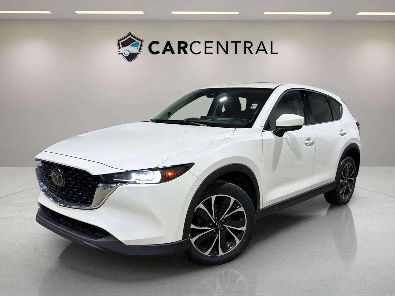 Sport Design, 2.5L 4-Cylinder Engine, 6-Speed Automatic Transmission, AWD, Leather Seats, Heated Front Seats, Heated Steering Wheel, Dual-Zone Climate Control, Power Driver Seat, Power Tailgate, 10.25" Display Screen, Navigation, Apple CarPlay, Android Auto, Bluetooth, Rear View Camera, Cruise Control, Keyless Entry, Push Button Start, 19" Alloy Wheels.

The 2022 Mazda CX-5 Sport Design is a compact SUV powered by a 2.5L Skyactiv-G 4-cylinder engine paired with a 6-speed automatic transmission and all-wheel drive, delivering smooth performance, confident handling, and refined everyday driving. It features a premium interior with upscale materials, advanced connectivity, and practical cargo versatility, making it a strong choice for comfort-focused commuting and all-season use. Available now in Barrie.

CARFAX: Free Carfax report on all our listing. Just go on our website and click view Carfax report.


CERTIFICATION: Have your new pre-owned vehicle certified at Car Central! We offer a full safety inspection exceeding industry standards including oil change, and professional detailing prior to delivery. Vehicles are not drivable, if not certified and not e-tested, certification package is available for $749. All trade-ins are welcome. Taxes, licensing are extra.


PRICE: We believe everyone deserves to get the best price possible on their new pre-owned vehicle without having to go through uncomfortable negotiations. Our Market Value Pricing (MVP) allows you to buy with confidence. We do this by constantly monitoring the market and adjusting our prices below the market average you can buy confidently knowing you are getting the best price possible! No haggle pricing. No pressure. Why pay more somewhere else. **CASH PRICE** will be an additional $1750 and it will include 1 Year or 15,000 kms Powertrain warranty. 


SERVICE: Schedule an appointment with Car Central Service Centre to bring your vehicle in for all its needs. Simply click on the link below and book your appointment. Our licensed technicians and repair facility offer the highest quality services at the most competitive prices. All work is manufacturer warranty approved and comes with 2-year parts and labour warranty. Start saving hundreds of dollars by servicing your vehicle with Car Central. Call us at 705-503-5000 or follow this link to book an appointment today! https://www.carcentral.ca/contact-us/


WARRANTY: This vehicle qualifies for an extended warranty with different terms and coverages available. Dont forget to ask for help choosing the right one for you.


FINANCING: No credit? New to the country? Bankruptcy? Consumer proposal? Collections? You dont need good credit to finance a vehicle. Bad credit is usually good enough. Give our finance and credit experts a chance to get you approved and start rebuilding credit today! On the spot financing, instant approvals, and no payments for 6 months is also available O.A.C!


Any vehicle stock number starting with Letter R are Previous daily Rental.


With over 30 years of experience, Car Central is a proud family-owned business and a trusted member of the UCDA. Our mission is to offer not only the best prices but also high-quality, reliable vehicles and an exceptional customer experience. We believe in making your car buying journey stress-free, with absolutely no pressurejust honest service you can rely on."