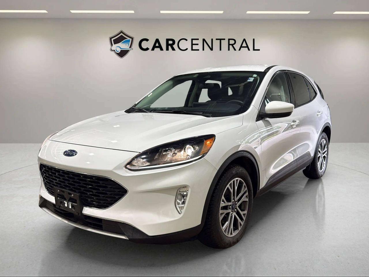 SEL Hybrid, AWD, Heated Front Seats, Remote Start, SYNC 3, Apple CarPlay & Android Auto, Heated Steering Wheel, Power Liftgate, Blind Spot Monitoring

Whether its crawling through morning traffic on Dunlop or stretching out on the 400 toward cottage country, this Escape SEL Hybrid keeps you in control  the AWD hybrid powertrain balances efficiency and traction while heated front seats and a heated steering wheel make January feel optional. Remote start means youre sliding into a warm cabin before youve even finished your coffee. Clean, connected, and ready for whatever the week throws at it. Available now in Barrie.

CARFAX: Free Carfax report on all our listing. Just go on our website and click view Carfax report.


CERTIFICATION: Have your new pre-owned vehicle certified at Car Central! We offer a full safety inspection exceeding industry standards including oil change, and professional detailing prior to delivery. Vehicles are not drivable, if not certified and not e-tested, certification package is available for $749. All trade-ins are welcome. Taxes, licensing are extra.


PRICE: We believe everyone deserves to get the best price possible on their new pre-owned vehicle without having to go through uncomfortable negotiations. Our Market Value Pricing (MVP) allows you to buy with confidence. We do this by constantly monitoring the market and adjusting our prices below the market average you can buy confidently knowing you are getting the best price possible! No haggle pricing. No pressure. Why pay more somewhere else. **CASH PRICE** will be an additional $1750 and it will include 1 Year or 15,000 kms Powertrain warranty. 


SERVICE: Schedule an appointment with Car Central Service Centre to bring your vehicle in for all its needs. Simply click on the link below and book your appointment. Our licensed technicians and repair facility offer the highest quality services at the most competitive prices. All work is manufacturer warranty approved and comes with 2-year parts and labour warranty. Start saving hundreds of dollars by servicing your vehicle with Car Central. Call us at 705-503-5000 or follow this link to book an appointment today! https://www.carcentral.ca/contact-us/


WARRANTY: This vehicle qualifies for an extended warranty with different terms and coverages available. Dont forget to ask for help choosing the right one for you.


FINANCING: No credit? New to the country? Bankruptcy? Consumer proposal? Collections? You dont need good credit to finance a vehicle. Bad credit is usually good enough. Give our finance and credit experts a chance to get you approved and start rebuilding credit today! On the spot financing, instant approvals, and no payments for 6 months is also available O.A.C!


Any vehicle stock number starting with Letter R are Previous daily Rental.


With over 30 years of experience, Car Central is a proud family-owned business and a trusted member of the UCDA. Our mission is to offer not only the best prices but also high-quality, reliable vehicles and an exceptional customer experience. We believe in making your car buying journey stress-free, with absolutely no pressurejust honest service you can rely on."