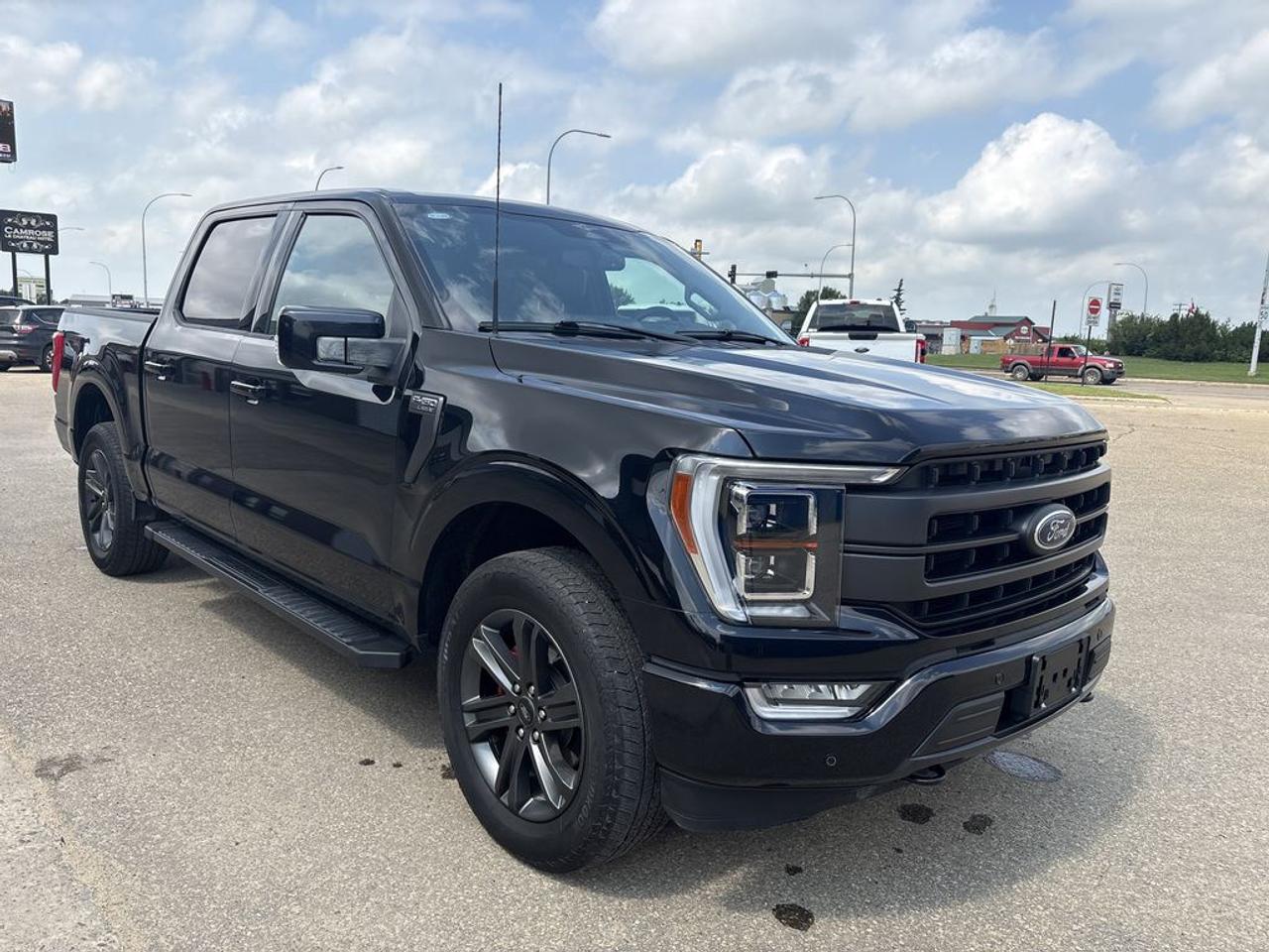 THE PRICE YOU SEE, PLUS GST. GUARANTEED!APPLE CARPLAY/ANDROID AUTO COMPATABLE!     Ford Blue Advantage.  Rates from 5.09% to 5.89% available.  Comes with Blue Plan - additional 6 / 10,000KM PreimiumCare ESP, SiriusXM 3 Month Activation, Connected Services Trial 90 days, 10,000 Ford Rewards Points, Full tank of Fuel.2.7 LITER ECOBOOST V6, 10 SPEED AUTO, LARIAT TRIM(502a), BLACK LEATHER TRIMMED SEATS, HEATED/VENTED FRONT SEATS, HEATED REAR SEATS, WIRELESS CHARGING PAD, TWIN PANEL MOONROOF, CO-PILOT 360 ASSIST 2.0, INTERIOR WORK SURFACE, TAILGATE STEP, SYNC 4 W/ 12 INFOTAINMENT TOUCHSCREEN, BLIS W/ CROSS TRAFFIC ALERT, LED BOX LIGHTS.     The 2023 Ford F-150 Lariat, equipped with the 2.7-liter EcoBoost engine, the 502A package, and Ford Co-Pilot 360 Assist 2.0, offers a well-rounded blend of power, luxury, and advanced safety features. The 2.7-liter EcoBoost V6 engine is renowned for its impressive balance of performance and efficiency, delivering strong torque and acceleration while maintaining good fuel economy, making it suitable for towing, hauling, and everyday driving. The 502A package enhances the trucks interior with premium materials, including leather-trimmed seats, a larger touchscreen infotainment system with SYNC 4, navigation, a premium audio system, and additional comfort and convenience features such as heated and ventilated seats, a digital instrument cluster, and advanced connectivity options. Ford Co-Pilot 360 Assist 2.0 adds a comprehensive suite of driver-assist technologies, including adaptive cruise control, lane-keeping assist, blind-spot monitoring, pre-collision assist with automatic emergency braking, and a 360-degree camera system, significantly enhancing safety and driving confidence. Do you want to know more about this vehicle, CALL, CLICK OR COME ON IN!*AMVIC Licensed Dealer; CarFax and Full Mechanical Inspection Included.