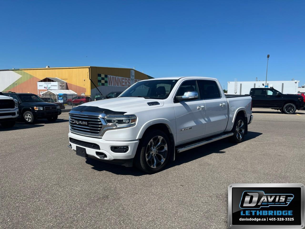 <b>Cooled Seats, Leather Seats, Premium Audio, Navigation, Android Auto!</b><br /> <br /> Discover the inner beauty and rugged exterior of this stylish Ram 1500. This 2022 Ram 1500 is fresh on our lot in Lethbridge.<br /> <br />The 2022 Ram 1500 does more than dominate the North American truck scene, it redefines. The Ram 1500 delivers power and performance everywhere you need it, with a tech-forward cabin that is all about comfort and convenience. Loaded with best-in-class features, it's easy to see why the Ram 1500 is so popular. With the most towing and hauling capability in a Ram 1500, as well as improved efficiency and exceptional capability, this truck has the grit to take on any task.<br /> <br />This Crew Cab 4X4 pickup has 58,099 km. Stock number 41712 is White in colour. It has an Automatic transmission and is powered by a 395HP 5.7L 8 Cylinder Engine. <br /> <br /> Our 1500's trim level is Longhorn. Upgrading to this premium Ram 1500 Longhorn is a great choice as it comes fully loaded with leather cooled and heated seats, exclusive aluminum wheels, chrome exterior accents, premium LED headlights, a heated leather steering wheel, and a large Uconnect touchscreen that's paired with navigation, Apple CarPlay, Android Auto, SiriusXM, and 4G LTE. Additional upscale features include a premium Alpine stereo, spray-in bed liner, power adjustable pedals and front seats, ParkSense front and rear sensors, proximity keyless entry, forward collision warning with active braking, power folding heated mirrors, and a rear step bumper to easily access your pickup's cargo area! This vehicle has been upgraded with the following features: Cooled Seats, Leather Seats, Premium Audio, Navigation, Android Auto, Apple CarPlay, Heated Steering Wheel.<br /> <br />To apply right now for financing use this link: <a href=https://lethbridge.davisdodge.ca/free-credit-check/ target=_blank rel=nofollow noopener noreferrer>https://lethbridge.davisdodge.ca/free-credit-check/</a><br /> <br /><br />Locally Owned & Trusted for Over 35 Years  Davis Dodge in Lethbridge, AB <br /><br /> At Davis Dodge, weve proudly served the Lethbridge community for more than 35 years, offering an unparalleled car buying experience. Dont just take our word for itour Google reviews speak volumes about our commitment to exceptional service. <br /><br /> Delivery & At-Home Test Drives: Convenient options to suit your lifestyle. <br /><br /> Flexible Financing for Everyone: Get the vehicle you need with financing solutions tailored to your situation. <br /><br /> Full Mechanical Inspections & Professional Cleaning: Every vehicle is thoroughly inspected and cleaned before it hits our lot.<br /><br /> We take all makes and models on trade and offer competitive pricing with inventory that changes daily. Whether you're shopping for a Chrysler, Dodge, Jeep, RAM, or FIAT, our AMVIC Licensed dealership makes it easy to browse, buy, and drive away.<br /><br /> Located in Lethbridge, AB, we proudly serve customers in Fort Macleod, Taber, Claresholm, and Coaldale. Shop online or visit us today to experience the best in sales, service, and selection. Standard bank rates apply; taxes are additional.<br /><br /> Vehicle pricing offer shown expires 2026-06-30. <br /> Come by and check out our fleet of 50+ used cars and trucks and 110+ new cars and trucks for sale in Lethbridge. o~o