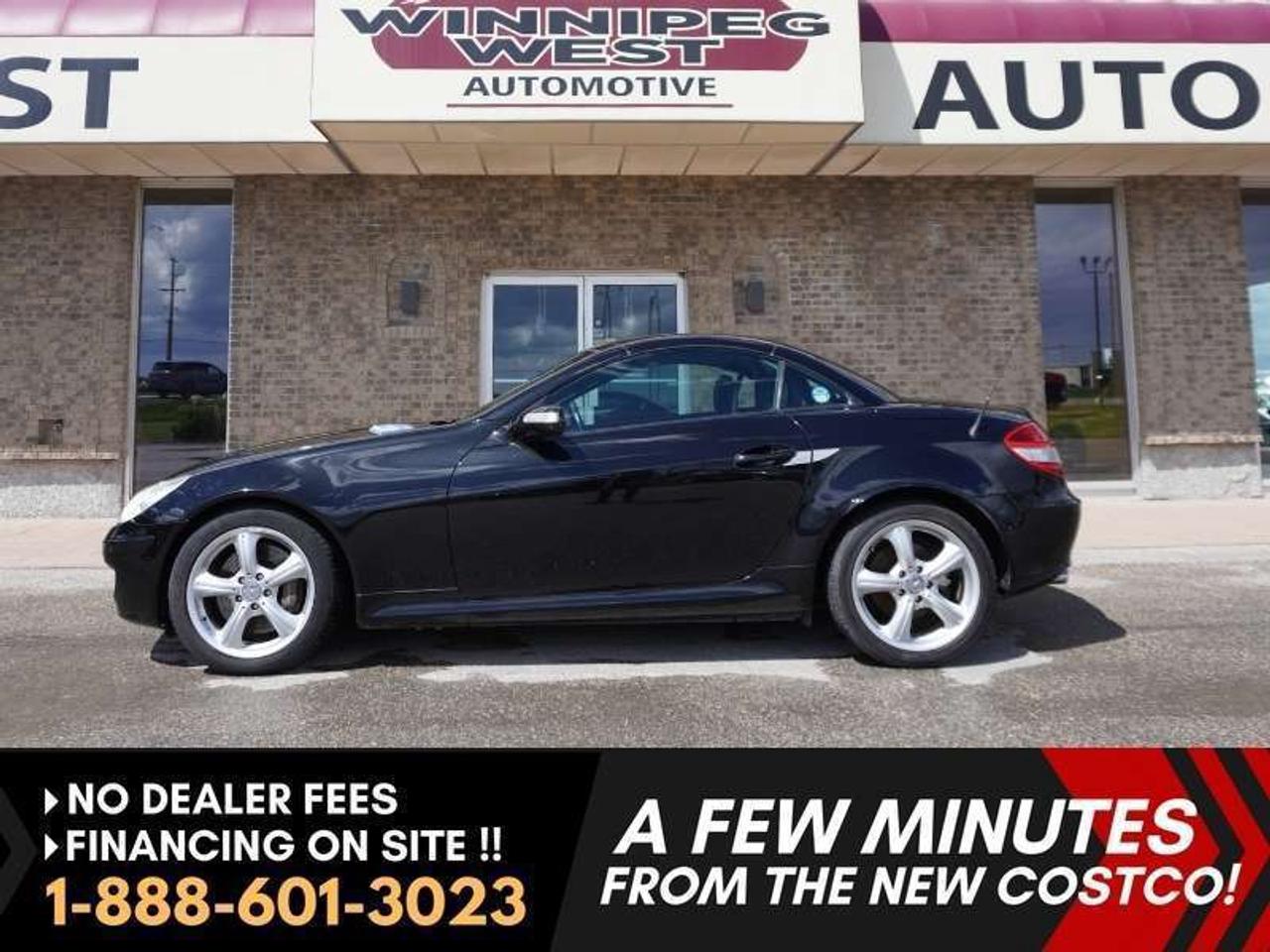 *** Dealer arranged financing on site! Quick, Simple,  no calls or waiting on bank appointments required!! Drive away today ***   NO ADMINISTRATION FEES!!Dealer arranged financing on-site! Quick, Simple, no calls or waiting on bank appointments required!! Drive away today ***   NO ADMINISTRATION FEES!! Highly sought-after 2006 Mercedes-Benz SLK 350 ** PREMIUM Right-hand drive Roadster ** Power-retractable Vario hardtop design (this vehicle is absolutely rust-free; undercarriage is spectacular!!  - - 7-speed automatic - - Premium heated leather seats - - AIRSCARF Neck-level Heating System - - Electronic Stability - - Harman/Kardon LOGIC7 Surround Sound System - - Leather steering wheel - - Chronograph-style gauges - - 8-way power-adjustable seats - - Dual-zone climate control - - Cruise controls - - Steering wheel controls - - Chromed hood vent covers - - Checkered race floor mats - - Roll hoops - - 5 Spoke 17" wheels  Second generation R171. Immaculate Obsidian Black exterior. Formula-one inspired long sleek hood with chrome accents. Immaculate inside and out.  Premium bucket seats. Premium leather upholstery. Fully redesigned dashboard. A stunning coupe/roadster! Absolutely beautiful and rare to find in this condition! Unique right hand drive.  <h5>Features</h5> - 3.5L DOHC V6 - 268 horsepower and 258 lb-ft of torque - 7-speed automatic - Rear-wheel drive - 17-inch alloy wheels - Harman Kardon Logic 7 premium sound system - Power windows - Power doors  - Power adjustable mirrors with LED turn signal lights - Heated Seats - Airscarf neck-level heating - Dual-zone climate control - 8-way power adjustable seats - Leather heated seats - Leather steering wheel - Cruise Control - 9-Speaker Harman Kardon sound system - Power-retractable hardtop  - Checkered race floor mats - Honeycomb hood vents with chrome accents - Rear defroster - 9.8 cubic feet cargo space - Perforated and ventilated 13-inch front disc brakes - Bi-Xenon headlights Comes with a Manitoba Safety Certification, and we have many Extended Powertrain warranties available on your vehicle purchase up to 10-year coverage (on eligible vehicles see dealer for details). Financing on site with Zero down financing OAC. Trades accepted. View at Winnipeg West Automotive Group, 5195 Portage Ave. (only a couple of minutes past the new Costco) Dealer permit # 6007, Call now 1(888) 6O1-3O23. This Car is located in Winnipeg Manitoba,  however we can have it shipped anywhere in North America relatively inexpensively.