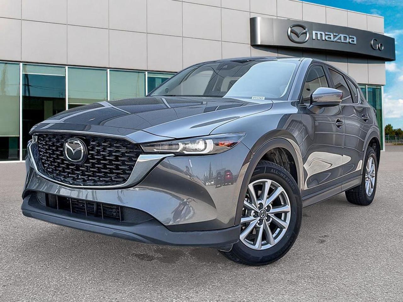 Experience refined driving with this pre-owned 2025 Mazda CX-5 GS AWD in striking Grey with a sleek Black leather interior. Powered by a 2.5L SKYACTIV-G engine paired with a smooth 6-speed automatic transmission and all-wheel drive, this SUV delivers both efficiency and confidence in any weather.Enjoy heated front leather seats, dual-zone automatic climate control, and a premium 6-speaker audio system for comfort and entertainment. Advanced safety features like lane departure prevention, blind-spot warning, and rearview camera keep you secure on every journey.With 19 Black Metallic Alloy Wheels, LED headlights, and convenient features such as a power liftgate and multiple USB ports, this CX-5 offers style and practicality. Ready for your next adventure  visit us today for a test drive and elevate your driving experience with Mazdas blend of performance and sophistication.