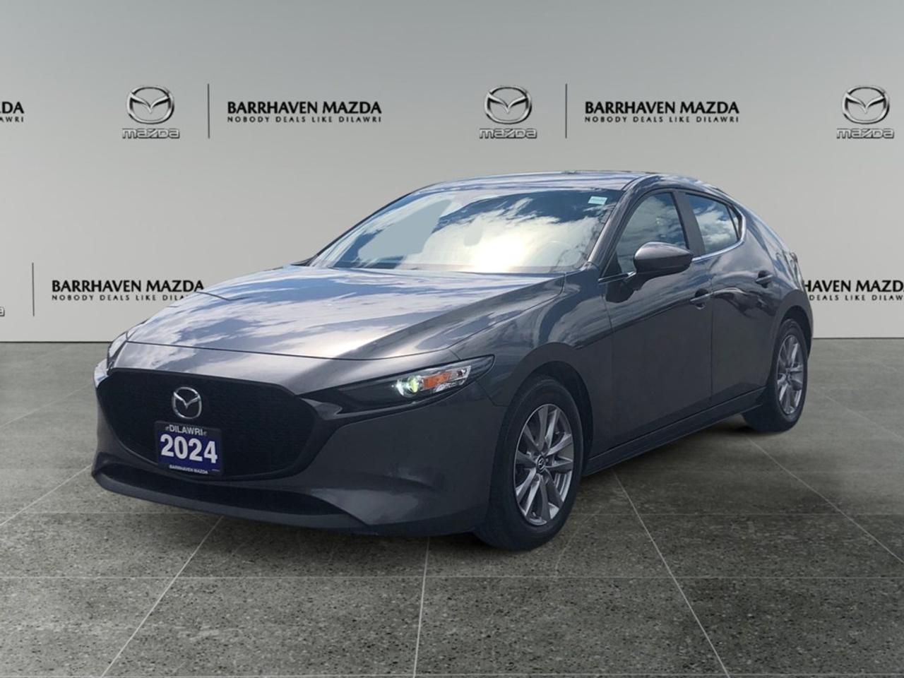 Get ready to experience the perfect blend of style and capability with the 2024 Mazda Mazda3 Sport GS Auto i-ACTIV AWD. Presented in an elegant gray finish, this hatchback is not only striking in appearance but also offers the exceptional handling of All-Wheel Drive, making it an ideal companion for Canadian roads. The Mazda3 Sport impresses from the outside with its sleek design and refined gray exterior. Inside, youre welcomed by a sophisticated interior featuring a leather steering wheel, leather gear shifter material, and leatherette door trim inserts. The spacious cabin is adorned with features designed for your comfort and convenience, including heated front seats, power-adjustable seats, and a smart integration for your devices. Enjoy the ambiance of the open sky with its sunroof/moonroof. Equipped with advanced technology, this Mazda3 offers a seamless driving experience. Stay connected with Bluetooth integration and take control effortlessly with the intuitive infotainment system. For your safety, it is equipped with adaptive cruise control, lane assist, and a dependable backup camera. Drive confidently with brake assist and cruise control enhancing your journey. This vehicle is perfect for those who value both style and performance. Whether youre zipping through city streets or cruising the open highway, the Mazda3 Sport is built to deliver. Visit Barrhaven Mazda to learn more and take this masterpiece for a test drive. Our team is ready to assist you with any questions, ensuring you find the perfect match for your lifestyle.