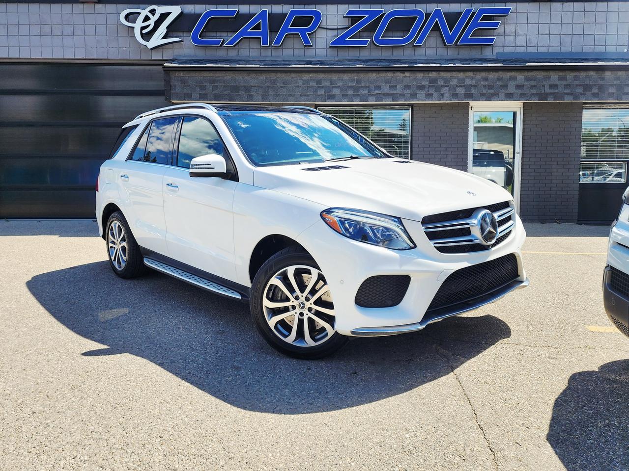 <p>Experience the refined power and sophisticated style of this used 2018 Mercedes-Benz GLE 400 4MATIC SUV, now available at Car Zone. Dressed in a classic white exterior that beautifully complements its sleek SUV profile, this Mercedes-Benz GLE commands attention on any road. Step inside to discover a luxurious black interior, designed to provide both comfort and a premium driving environment for you and your passengers. Under the hood, a potent 3L I6 Turbo engine is paired with an automatic transmission and All-Wheel Drive, ensuring a dynamic and confident driving experience in all Canadian conditions. With 114,770 km on the odometer, this meticulously maintained GLE is ready for its next adventure.</p><p>This 2018 Mercedes-Benz GLE 400 4MATIC SUV offers a blend of performance, luxury, and advanced technology. Its spacious interior and versatile body style make it an ideal choice for families, professionals, or anyone seeking a capable and stylish vehicle. Whether navigating city streets or embarking on a weekend getaway, this GLE delivers a smooth, powerful, and connected ride. Visit Car Zone today to see why this Mercedes-Benz GLE is the perfect combination of elegance and practicality.</p><p>Here are five standout features of this 2018 Mercedes-Benz GLE 400 4MATIC SUV:</p><ul><li><strong>3L I6 Turbo Engine:</strong> Unleash exhilarating performance with the responsive and powerful turbocharged inline-six engine, offering impressive acceleration and a thrilling driving dynamic.</li><li><strong>4MATIC All-Wheel Drive:</strong> Conquer any road, any season, with the legendary 4MATIC all-wheel-drive system, providing superior traction, stability, and confidence in diverse Canadian weather.</li><li><strong>Luxurious Black Interior:</strong> Sink into the embrace of a meticulously crafted black interior, exuding sophistication and offering unparalleled comfort for every journey.</li><li><strong>Sleek White Exterior:</strong> Turn heads with the timeless elegance of its pristine white exterior, showcasing the GLEs sophisticated design and premium appeal.</li><li><strong>SUV Versatility:</strong> Enjoy the perfect fusion of car-like handling and SUV practicality, offering ample cargo space and a commanding view of the road.</li></ul><p>Looking for Your Dream Car? Call Car Zone Today!</p><p>Thanks for viewing our Car Zone inventory. All of our vehicles come fully detailed with a Carfax and a mechanical fitness assessment. Drive this home today! Easy financing options. All credit welcome.&nbsp;<strong><a href=http://www.calgary.ca/finance>APPLY NOW</a>&nbsp;</strong>We even take trades. Same day approvals at&nbsp;<a href=http://www.carzonecalgary.ca/><strong>CARZONECALGARY</strong></a> or visit us in person at 2036 36 Street SE Calgary for a hassle free test drive. Let our friendly team of experts book an appointment with you and show you the Car Zone difference! AMVIC licensed dealer.&nbsp;</p>