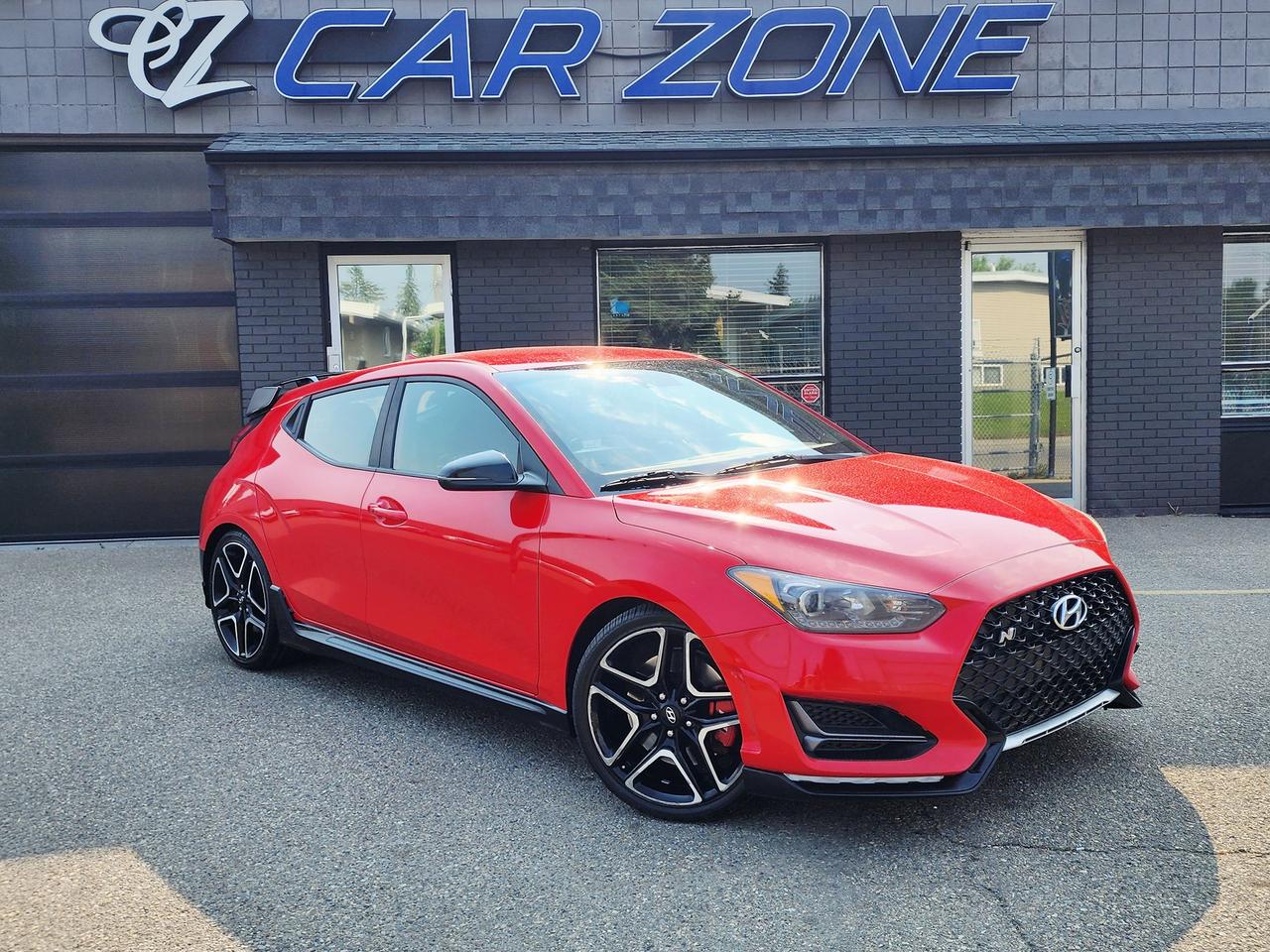 <p>Get ready to ignite your passion for driving with this stunning, red 2021 Hyundai Veloster Manual, now available at Car Zone! This isnt just any coupe; its a statement of performance and style, wrapped in a vibrant red exterior thats sure to turn heads on every corner. Step inside the sleek black interior and youll find a cockpit designed for the true enthusiast, ready to deliver an exhilarating driving experience. With a robust 2.0L I4 Turbo engine paired with a classic manual transmission, this Veloster offers a direct connection to the road, making every shift a satisfying engagement. Its the perfect choice for drivers who crave control and a responsive feel.</p><p>This 2021 Hyundai Veloster is more than just a car; its an opportunity to own a dynamic and fun-to-drive vehicle thats perfect for navigating city streets or embarking on weekend adventures. This Veloster has been well-travelled and is ready for many more exciting journeys. At Car Zone, we pride ourselves on offering quality pre-owned vehicles that deliver exceptional value and driving pleasure, and this Veloster is a prime example of that commitment.</p><p>Here are 5 features that truly make this 2021 Hyundai Veloster Manual sizzle:</p><ul><li><strong>Thrilling 2.0L Turbocharged Engine:</strong> Unleash raw power and responsive acceleration with this potent engine, built for spirited driving.</li><li><strong>Engaging Manual Transmission:</strong> Experience the pure joy of a true drivers car with the classic manual gearbox, putting you in complete command.</li><li><strong>Eye-Catching Red Exterior:</strong> Make a bold statement with its vibrant red paint, ensuring you stand out from the crowd.</li><li><strong>Sporty Coupe Design:</strong> Embrace the dynamic and athletic silhouette of this unique three-door coupe.</li><li><strong>Front-Wheel Drive Dynamics:</strong> Enjoy agile handling and a connected feel to the road, perfect for carving through corners.</li></ul><p>Looking for Your Dream Car? Call Car Zone Today!</p><p>Thanks for viewing our Car Zone inventory. All of our vehicles come fully detailed with a Carfax and a mechanical fitness assessment. Drive this home today! Easy financing options. All credit welcome.&nbsp;<strong><a href=http://www.calgary.ca/finance>APPLY NOW</a>&nbsp;</strong>We even take trades. Same day approvals at&nbsp;<a href=http://www.carzonecalgary.ca/><strong>CARZONECALGARY</strong></a> or visit us in person at 2036 36 Street SE Calgary for a hassle free test drive. Let our friendly team of experts book an appointment with you and show you the Car Zone difference! AMVIC licensed dealer.&nbsp;</p>