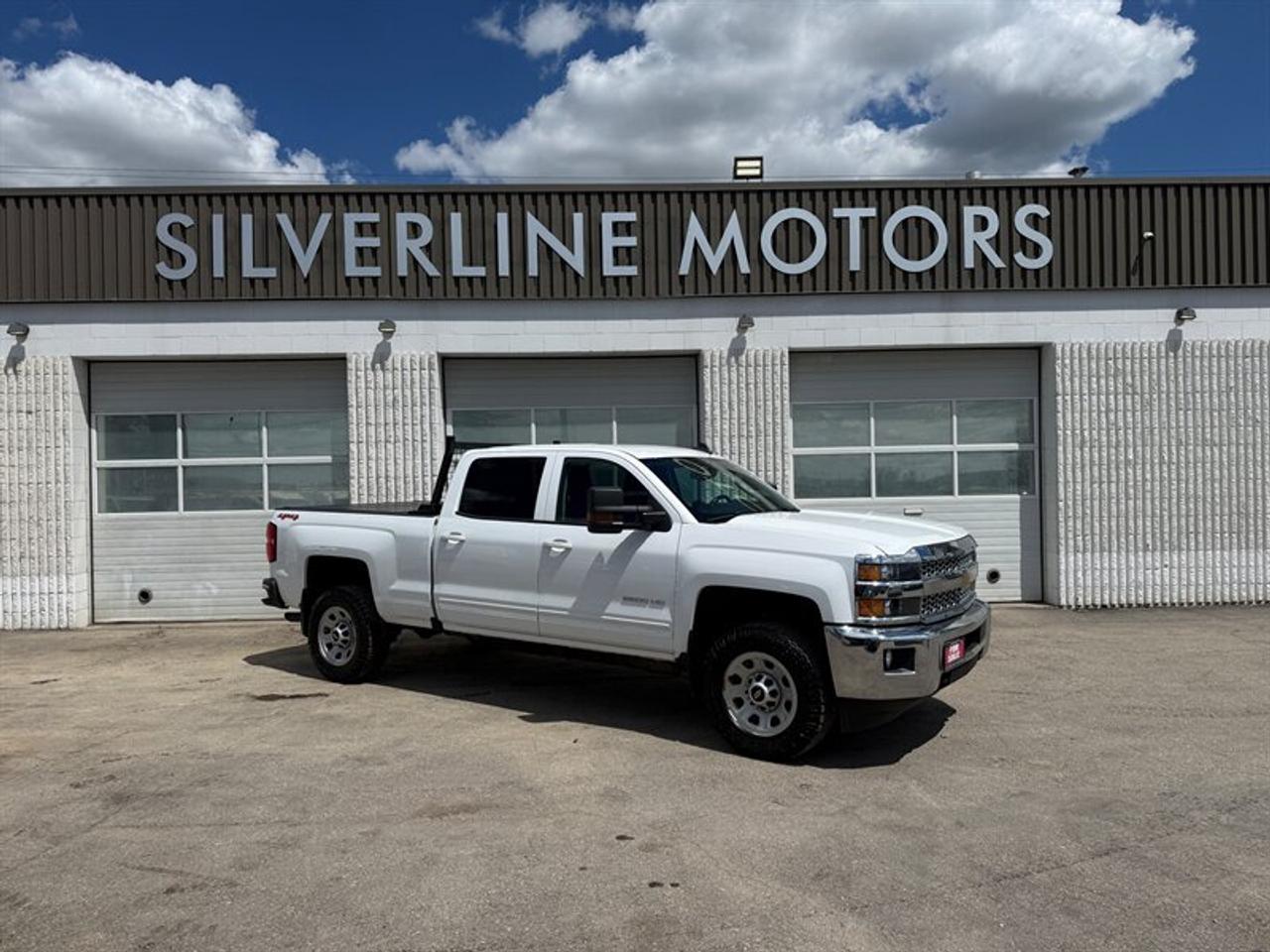 ***WHY BUY FROM SILVERLINE?***

*FINANCING AVAILABLE*

*CLEAN TITLE ONLY*

*TRADE-INS WELCOME*

*7 DAY INSURANCE*

*3 MONTH WARRANTY/5000KM LIMITED POWERTRAIN WARRANTY*

*MB SAFETY*

*NATIONWIDE DELIVERY AVAILABLE*

*D#4140* ****

****READY TO WORK TRUCK IS HERE! CHEVROLET SILVERADO 2500HD, 6.0 GAS, 4X4, AUTO, CREW CAB, BACK-UP CAM AND BLUETOOTH, POWER WINDOWS AND LOCKS, POWER MIRRORS, ALARM, KEYLESS ENTRY, AM FM CD, CRUISE, ABS, BOX IS LINED WITH SPRAY IN LINER, BOX HAS BUILT IN SLIDEOUT TRAY, HARD FOLDABLE TONNEAU COVER, BACK RACK, HITCH, TOW PACKAGE, CHROME BUMPERS FRONT AND REAR, TOW MIRRORS, TINTED GLASS, ALL NEW BRAKES FRONT AND REAR, FRESH OIL CHANGE, 2 KEYS AND WARRANTY INCLUDED!





*****VALUE PRICED AT $26,991+TAX, WARRANTY INCLUDED******

*****VIEW AT SILVERLINE MOTORS, 1601 NIAKWA RD EAST******

*****CALL/TEXT 204-509-0008*****



INSTALLED FEATURES: Air filtration, Front air conditioning, Front air conditioning zones: single, Airbag deactivation: occupant sensing passenger, Front airbags: dual, Side airbags: front, Side curtain airbags: front / rear, Antenna type: diversity / mast, Auxiliary audio input: Bluetooth / iPod/iPhone / jack / USB, In-Dash CD: MP3 Playback / single disc, Internet radio app: iHeartRadio / Pandora, Radio: AM/FM / HD radio / touch screen display / voice operated, Radio data system, Satellite radio: SiriusXM, Speed sensitive volume control, Total speakers: 6, ABS: 4-wheel, Braking assist, Electronic brakeforce distribution, Front brake type: ventilated disc, Power brakes, Rear brake type: ventilated disc, Armrests: front center / rear center with cupholders / rear folding, Floor mat material: rubber/vinyl, Floor material: carpet, Floor mats: front / rear, Steering wheel trim: leather, Assist handle: front / rear, Capless fuel filler system, Cruise control, Cupholders: front / rear, Multi-function remote: keyless entry / panic alarm, One-touch windows: 4, Overhead console: front, Power outlet(s): 12V front, Power steering: hydraulic variable assist / variable/speed-proportional, Power windows: lockout button, Reading lights: front, Rearview mirror: manual day/night, Steering wheel: tilt, Steering wheel mounted controls: audio / cruise control / voice control, Storage: door pockets / front seatback / in seat cushion / sunglasses holder, Vanity mirrors: dual illuminating, Body side moldings: body-color, Bumper detail: rear integrated corner step, Door handle color: body-color, Exhaust tip color: stainless steel, Front bumper color: chrome, Grille color: chrome, Mirror color: body-color, Pickup bed light, Rear bumper color: chrome, Tailgate: power locking / removable, Window trim: black, Connected in-car apps: app marketplace integration, Infotainment: Chevrolet Infotainment System, Infotainment screen size: 8 in., Smartphone integration: Android Auto / Apple CarPlay, Clock, Digital odometer, External temperature display, Fuel economy display: MPG / range, Gauge: oil pressure / tachometer, Instrument cluster screen size: 4.2 in., Multi-function display, Powertrain hour meter, Trip odometer, Warnings and reminders: coolant temperature warning / lamp failure / low battery / low fuel level / low oil pressure / maintenance due, Daytime running lights, Headlights: auto delay off / auto on/off / halogen, Side mirror adjustments: manual folding / power, Side mirrors: heated, 4WD selector: electronic hi-lo, 4WD type: part time, Alternator: 150 amps, Auxiliary oil cooler, Auxiliary transmission fluid cooler, Battery: heavy duty / maintenance-free, Battery rating: 720 CCA, Battery saver, Locking differential: rear, Camera system: rearview, Check rear seat reminder, Child safety door locks, Child seat anchors: LATCH system, Programmable safety key, Rearview monitor: in dash, Emergency locking retractors: front, Front seatbelts: 3-point, Rear seatbelts: 3-point, Seatbelt pretensioners: front, Seatbelt warning sensor: front, Driver seat manual adjustments: 6 / lumbar / reclining, Front headrests: 2 / adjustable, Front seat type: 40-20-40 split bench, Passenger seat manual adjustments: 4 / reclining, Rear headrests: 2 / adjustable, Rear seat folding: folds up, Rear seat type: 60-40 split bench, Upholstery: cloth, Anti-theft system: vehicle immobilizer, Power door locks: anti-lockout / auto-locking, Hill holder control, Roll stability control, Stability control, Traction control, Trailer stability control, Front shock type: twin-tube gas, Front spring type: torsion bars, Front stabilizer bar: diameter 33 mm, Front suspension classification: independent, Front suspension type: short and long arm, Rear shock type: twin-tube gas, Rear spring type: leaf, Rear suspension classification: solid live axle, Rear suspension type: multi-leaf, Driver assistance app: roadside assistance, Electronic messaging assistance: voice operated / with read function, Hands-free phone call integration: voice operated, Satellite communications: OnStar / voice guided directions, Smart device app compatibility: myChevrolet with Connected Access, Smart device app function: maintenance status, Wi-Fi: hotspot, Wireless data link: Bluetooth, Tow hooks: front, Tow/Haul mode, Spare tire mount location: underbody, Spare tire size: full-size, Spare wheel type: steel, Tire Pressure Monitoring System, Wheels: aluminum alloy, Front wipers: variable intermittent, Power windows: safety reverse, Tinted glass