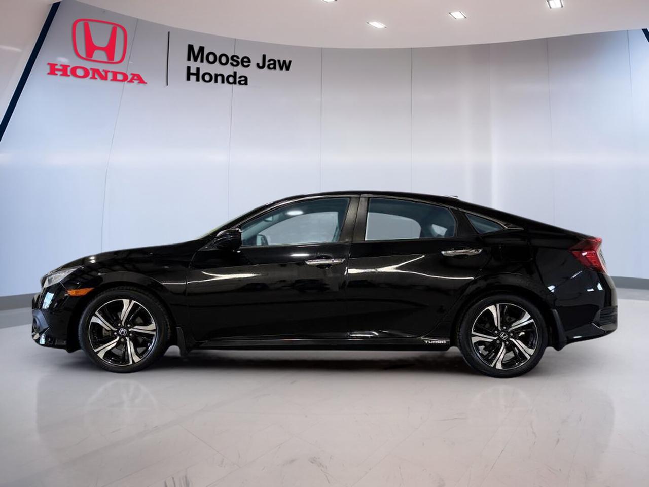 The 2017 Honda Civic Base Coupe at Moose Jaw Honda delivers sharp style, turbocharged performance, and proven everyday value in one smart package. Finished in Black with a matching Black interior, this used coupe has 113,939 km and a continuously variable transmission for smooth, efficient driving around Moose Jaw and beyond.

Powered by a 1.5-litre turbocharged 4-cylinder engine, the 2017 Honda Civic Base Coupe brings lively response and excellent fuel economy together. Its front-wheel drive layout helps provide confident road manners in changing conditions, while the sleek two-door design gives this Civic Base a sporty character that still feels practical for daily use.

FEATURES OF THE Civic Base

»» 1.5-litre turbocharged four-cylinder engine included
»» Continuously variable transmission for smooth shifting
»» Front-wheel drive for balanced handling
»» Black exterior with Black interior

ADVANCED SAFETY FEATURES

»» Vehicle Stability Assist helps maintain control
»» Anti-lock braking system supports confident stops
»» Advanced airbag system enhances occupant protection
»» Tire Pressure Monitoring System adds awareness

PERFORMANCE AND EFFICIENCY

»» Turbo engine delivers responsive everyday power
»» Continuously variable transmission improves fuel efficiency
»» Front-wheel drive supports predictable road manners
»» Civic Base Coupe feels agile in traffic

COMFORT AND CONVENIENCE

»» Two-door layout adds easy front access
»» Cabin design keeps controls close
»» Smart interior space for daily driving
»» Compact size helps urban parking ease

TECHNOLOGY AND CONNECTIVITY

»» Easy-to-read gauges support quick information
»» Simple control layout reduces distraction
»» Clear driver display aids awareness
»» Modern engineering supports daily usability

CARGO SPACE

»» Rear seatback expands carrying flexibility
»» Trunk space suits everyday errands
»» Coupe design still offers useful storage
»» Cabin includes practical small-item spaces

AWARDS & RECOGNITIONS

»» North American Car of the Year, 2016
»» Top Safety Pick, Insurance Institute for Highway Safety, 2017
»» Best Small Car, Automobile Journalists Association of Canada, 2016

WHAT OTHER OWNERS LIKE

»» Strong turbo power for daily driving
»» Smooth ride with composed handling
»» Great fuel economy in real use
»» Stylish coupe shape with practical value

This 2017 Honda Civic Base Coupe stands out for drivers who want more than basic transportation. The turbocharged engine gives it extra energy, and the CVT keeps the drive refined and easy. In town, it feels nimble and simple to place. On the highway, it stays composed and efficient.

The Black-on-Black colour combination gives this 2017 Honda Civic Base Coupe a clean, sporty look that suits its modern design. It is a smart choice for commuters, first-time buyers, and anyone searching for a dependable used coupe with a strong reputation for quality and long-term satisfaction.

At Moose Jaw Honda, this 2017 Honda Civic Base Coupe offers a great mix of style, efficiency, and trusted engineering. If you want a well-known compact coupe with turbocharged performance and everyday practicality, this Civic deserves a close look.

This 2017 Honda Civic Bases VIN is: 2HGFC1F95HH105607 .<p> efficient driving around Moose Jaw and beyond.

Powered by a 1.5-litre turbocharged 4-cylinder engine</p>
<p> the 2017 Honda Civic Base Coupe brings lively response and excellent fuel economy together. Its front-wheel drive layout helps provide confident road manners in changing conditions</p>
<p> while the sleek two-door design gives this Civic Base a sporty character that still feels practical for daily use.

FEATURES OF THE Civic Base

»» 1.5-litre turbocharged four-cylinder engine included
»» Continuously variable transmission for smooth shifting
»» Front-wheel drive for balanced handling
»» Black exterior with Black interior

ADVANCED SAFETY FEATURES

»» Vehicle Stability Assist helps maintain control
»» Anti-lock braking system supports confident stops
»» Advanced airbag system enhances occupant protection
»» Tire Pressure Monitoring System adds awareness

PERFORMANCE AND EFFICIENCY

»» Turbo engine delivers responsive everyday power
»» Continuously variable transmission improves fuel efficiency
»» Front-wheel drive supports predictable road manners
»» Civic Base Coupe feels agile in traffic

COMFORT AND CONVENIENCE

»» Two-door layout adds easy front access
»» Cabin design keeps controls close
»» Smart interior space for daily driving
»» Compact size helps urban parking ease

TECHNOLOGY AND CONNECTIVITY

»» Easy-to-read gauges support quick information
»» Simple control layout reduces distraction
»» Clear driver display aids awareness
»» Modern engineering supports daily usability

CARGO SPACE

»» Rear seatback expands carrying flexibility
»» Trunk space suits everyday errands
»» Coupe design still offers useful storage
»» Cabin includes practical small-item spaces

AWARDS & RECOGNITIONS

»» North American Car of the Year</p>
<p> 2016

WHAT OTHER OWNERS LIKE

»» Strong turbo power for daily driving
»» Smooth ride with composed handling
»» Great fuel economy in real use
»» Stylish coupe shape with practical value

This 2017 Honda Civic Base Coupe stands out for drivers who want more than basic transportation. The turbocharged engine gives it extra energy</p>
<p> it stays composed and efficient.

The Black-on-Black colour combination gives this 2017 Honda Civic Base Coupe a clean</p>
<p> and anyone searching for a dependable used coupe with a strong reputation for quality and long-term satisfaction.

At Moose Jaw Honda</p>
<p> and trusted engineering. If you want a well-known compact coupe with turbocharged performance and everyday practicality</p>