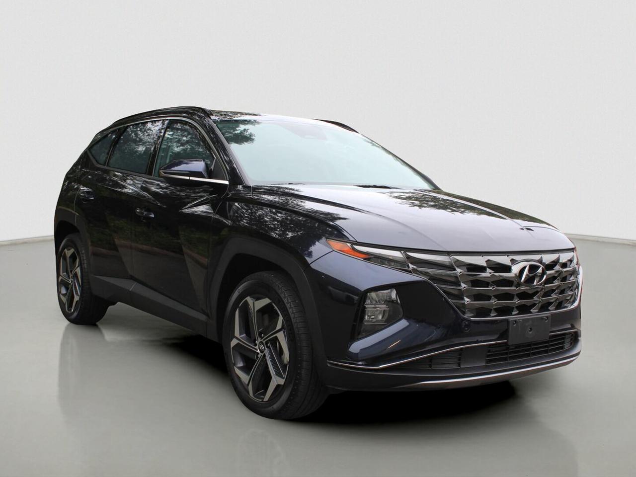 Discover efficient hybrid driving in this 2023 Hyundai Tucson Hybrid Luxury AWD, now available at Courtenay Kia in Courtenay. CARFAX Canada reports no accidents, and this SUV has had a single owner. With its blue exterior, automatic transmission, and 86,791 km, this hybrid delivers smart value every day.

This 2023 Hyundai Tucson Hybrid Luxury AWD blends confident all-wheel drive capability with fuel-saving hybrid performance. Its 1.6 L hybrid engine works with a 6-speed automatic transmission for smooth response in traffic and steady power on the highway. It is a practical hybrid SUV built for West Coast driving.

FEATURES OF THE Tucson Hybrid Luxury AWD
»» Panoramic sunroof brightens the roomy cabin
»» Navigation system helps guide every trip
»» Heated front and rear seats included
»» Power liftgate adds everyday convenience

HYBRID VEHICLE FEATURES
»» Hybrid power supports lower fuel use
»» Gas and electric power work smoothly
»» Quiet operation during light throttle driving
»» Efficient design suits daily commuting well

ADVANCED SAFETY FEATURES
»» Backup camera helps with safer reversing
»» Blind spot monitor adds lane awareness
»» Lane departure warning supports safer travel
»» Multiple airbags help protect occupants

PERFORMANCE AND EFFICIENCY
»» 1.6 L hybrid engine saves fuel
»» All-wheel drive adds year-round confidence
»» Six-speed automatic shifts smoothly and quickly
»» Stability control supports confident handling

COMFORT AND CONVENIENCE
»» Dual-zone climate control adds cabin comfort
»» Heated mirrors help in cold weather
»» Driver lumbar support improves long drives
»» Remote starter adds welcome daily ease

TECHNOLOGY AND CONNECTIVITY
»» Bluetooth integration supports hands-free calling
»» Steering wheel audio controls add convenience
»» Satellite radio expands entertainment choices
»» Push button start simplifies every departure

CARGO SPACE
»» Rear trunk access makes loading easier
»» Power liftgate helps with busy days
»» Four-door layout improves passenger entry
»» Rear space suits errands and travel

AWARDS & RECOGNITIONS
»» Top Safety Pick, Insurance Institute for Highway Safety, 2023
»» Best Compact Utility Vehicle, Automobile Journalists Association of Canada, 2022

WHAT OTHER OWNERS LIKE
»» Smooth hybrid power for daily driving
»» Comfortable cabin with useful tech features
»» Easy visibility and practical cargo room
»» Confident all-wheel drive in poor weather

This used hybrid SUV is well equipped with cruise control, power steering, ABS, stability control, child safety locks, heated mirrors, power windows, automatic headlights, LED headlamps, tinted windows, and a rear spoiler. The panoramic sunroof and ambient lighting package add a refined feel without giving up everyday function.

Inside, this 2023 Hyundai Tucson Hybrid Luxury AWD offers a comfortable and modern space for drivers and passengers alike. You also get a power drivers seat, leather steering wheel, automatic climate control, HD Radio, an auto-dimming rearview mirror, and illuminated vanity mirrors. It is a hybrid SUV designed to make every trip easier.

If you want a hybrid SUV that balances comfort, efficiency, safety, and all-wheel drive confidence, this 2023 Hyundai Tucson Hybrid Luxury AWD stands out for all the right reasons. With single-owner history, a clean CARFAX Canada report, and strong equipment, it is ready for its next adventure on Vancouver Island.

Come and visit Courtenay Kia and experience our brand new, State-of-the-art Facility where you will find one of North Vancouver Islands largest selection of New and Pre-Owned Vehicles, Friendly and Knowledgeable Sales staff and a team of Finance Professionals that will secure the best finance arrangements, whether you have great credit or not-so-great!

$699.00 Documentation Fee Applies, Taxes Extra

Stock # SP5213A

Dealer # 30891
1025A Comox Road
Courtenay BC V9N 3P7