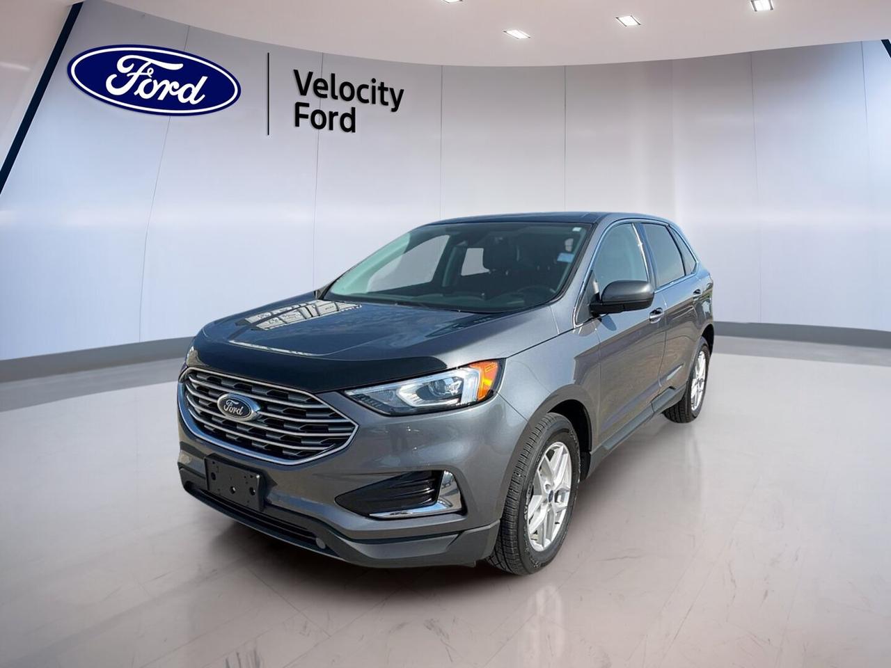 The 2022 Ford Edge SEL AWD is a smart choice for drivers in Moose Jaw who want comfort, confidence, and everyday versatility in one well-equipped SUV. Finished in Grey with a Black interior, this used 2022 Ford Edge SEL AWD offers a refined look, four-door practicality, and the confidence of all-wheel drive for changing Prairie road conditions.

Powered by a 2.0-litre unleaded engine paired with an 8-speed automatic transmission, this 2022 Ford Edge SEL AWD delivers smooth power for commuting, highway travel, and weekend errands. With 171,196 km on the odometer, it has already proven its road-going capability while continuing to offer the features many drivers want most.

FEATURES OF THE Edge SEL AWD

»» All-wheel drive for year-round road confidence
»» 2.0-litre turbocharged four-cylinder engine performance
»» Eight-speed automatic delivers smooth shifting
»» Four-door SUV practicality for daily use

ADVANCED SAFETY FEATURES

»» Backup camera helps with safer reversing
»» Blind spot monitor adds lane awareness
»» Lane departure warning supports highway confidence
»» Multiple airbags help protect occupants

PERFORMANCE AND EFFICIENCY

»» 2.0-litre engine balances power and efficiency
»» Automatic transmission supports smooth daily driving
»» Stability control improves handling on slick roads
»» Limited slip differential boosts traction control

COMFORT AND CONVENIENCE

»» Heated front seats add winter comfort
»» Dual-zone climate control improves cabin comfort
»» Remote starter helps on cold mornings
»» Power driver seat includes lumbar support

TECHNOLOGY AND CONNECTIVITY

»» Bluetooth integration supports hands-free communication
»» WiFi hotspot keeps passengers more connected
»» Satellite radio expands entertainment choices
»» Steering wheel audio controls ease use

CARGO SPACE

»» Power liftgate helps with daily loading
»» Rear trunk access adds useful practicality
»» Spacious rear area suits busy lifestyles
»» Four-door design simplifies passenger and cargo entry

AWARDS & RECOGNITIONS

»» Top Safety Pick, Insurance Institute for Highway Safety, 2022

WHAT OTHER OWNERS LIKE

»» Comfortable ride quality for daily travel
»» Confident all-wheel drive in poor weather
»» User-friendly infotainment and cabin controls
»» Quiet cabin during highway driving

This used SUV is equipped with practical features that make every drive easier. Highlights include cruise control, power steering, anti-lock braking system, heated mirrors, power windows, automatic headlights, LED headlamps, tinted windows, rear spoiler, push-button start, auto-dimming rearview mirror, rear window defroster, and automatic door locks. The cabin also includes front air conditioning, automatic climate control, illuminated vanity mirrors, and a leather steering wheel for a more polished feel.

For peace of mind and convenience, this vehicle also includes child safety locks, tire pressure monitoring, passenger airbag sensor, head side airbags, side impact airbags, and a driver airbag. The electric passenger seat adds flexibility, while the spare tire helps you stay prepared on the road. Sold by Velocity Ford in Moose Jaw, this 2022 Ford Edge SEL AWD brings together value, utility, and everyday comfort in a well-appointed package.

This 2022 Ford Edge SEL AWDs VIN is: 2FMPK4J95NBA13289.