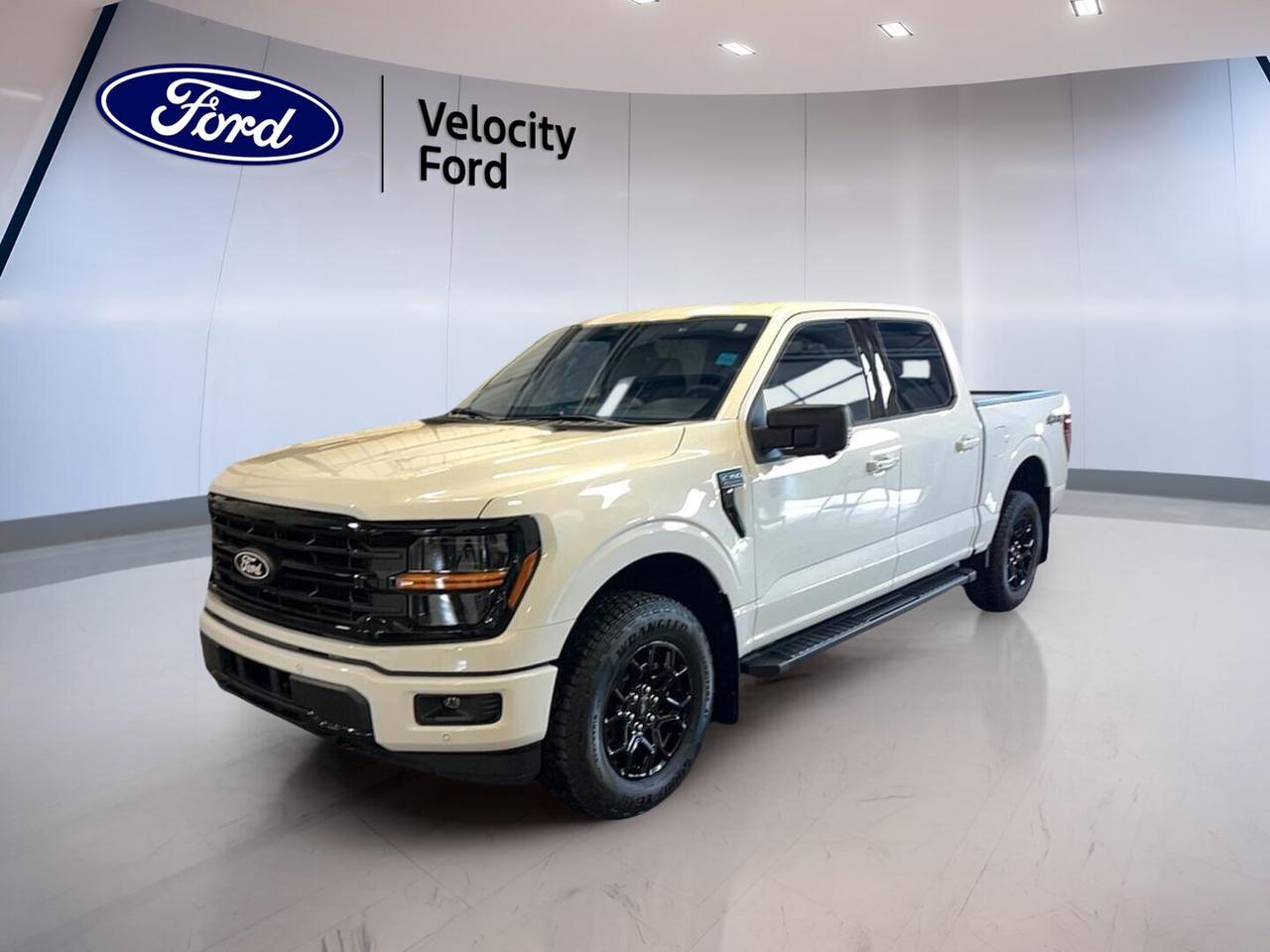 Built for hard work and daily comfort, the brand new 2026 Ford F-150 XLT 4WD SuperCrew 5.5 Box is ready for life in Moose Jaw. Its White exterior and Black interior give this full-size pickup a clean, confident look. With four doors, automatic transmission, and a 2.7-litre unleaded engine, this truck delivers the capability Canadian drivers want.

Sold by Velocity Ford, this new 2026 Ford F-150 XLT 4WD SuperCrew 5.5 Box blends practical features with proven truck strength. The roomy SuperCrew cab adds easy access for passengers and gear. Four-wheel drive, off-road tires, and a strong 4,671 kg towing capacity help this pickup handle job sites, weekend trailers, and changing prairie weather with confidence.

FEATURES OF THE F-150 XLT 4WD SuperCrew 5.5 Box
»» SuperCrew cab adds roomy rear seating
»» 5.5-foot box supports daily hauling needs
»» XLT trim balances value and utility
»» Four-wheel drive boosts year-round traction

TRUCK FEATURES
»» Tows up to 4,671 kg confidently
»» Rear tow hook aids recovery situations
»» Off-road tires support rougher terrain
»» Short box helps urban manoeuvrability

ADVANCED SAFETY FEATURES
»» Backup camera helps with reversing visibility
»» Blind spot monitor adds lane awareness
»» Lane departure warning supports safer travel
»» Multiple airbags enhance occupant protection

PERFORMANCE AND EFFICIENCY
»» 2.7-litre unleaded engine delivers solid power
»» Automatic transmission supports smooth daily driving
»» Dual shift mode adds manual control
»» Four-wheel drive improves traction on roads

COMFORT AND CONVENIENCE
»» Front air conditioning keeps cabin comfortable
»» Power windows add everyday convenience
»» Heated mirrors help in cold weather
»» Driver lumbar support aids longer drives

TECHNOLOGY AND CONNECTIVITY
»» Bluetooth integration supports hands-free calling
»» WiFi hotspot keeps devices connected
»» Satellite radio expands entertainment choices
»» Steering wheel audio controls simplify use

CARGO SPACE
»» 5.5-foot box handles everyday cargo loads
»» Rear trunk access supports loading ease
»» Spare tire adds roadside peace
»» Four-door cab offers added interior storage

WHAT OTHER OWNERS LIKE
»» Strong towing for work and recreation
»» Comfortable cabin with useful tech
»» Confident four-wheel drive capability
»» Easy driving with practical visibility

This new pickup is well equipped with key features drivers value every day. Cruise control and power steering help make longer trips easier. Anti-lock braking system, stability control, tire pressure monitoring, child safety locks, automatic headlights, fog lights, tinted windows, rear window defroster, power mirrors, illuminated vanity mirrors, and automatic door locks all add practical support.

For drivers who need a modern truck without excess, this 2026 Ford F-150 XLT 4WD SuperCrew 5.5 Box is a smart fit. It offers the comfort of a spacious cab, the confidence of advanced safety equipment, and the utility expected from a Ford truck. Whether towing, commuting, or heading out beyond the pavement, this new F-150 is prepared to get the job done.

This 2026 Ford F-150 XLT 4WD SuperCrew 5.5 Boxs VIN is: 1FTEW3LP0TKD75829.
