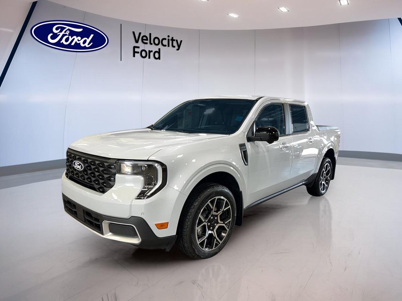 Meet the brand new 2026 Ford Maverick LARIAT AWD at Velocity Ford in Moose Jaw. This compact truck blends everyday comfort, modern tech, and true pickup usefulness in one smart package. Finished in White with a Grey interior, it brings a clean look and practical design to workdays, errands, and weekend trips.

The 2026 Ford Maverick LARIAT AWD is built for drivers who want truck capability without the bulk of a full-size pickup. With 4 doors, a 2.0-litre unleaded engine, and all-wheel drive confidence, it is ready for changing Prairie weather while staying easy to park and easy to live with.

FEATURES OF THE Maverick LARIAT AWD

»» White exterior with Grey cabin finish
»» All-wheel drive for added traction
»» 2.0-litre unleaded engine power
»» Four-door crew cab practicality

TRUCK FEATURES

»» Towing capacity rated at 907 kg
»» Rear tow hook adds utility
»» Compact size suits city driving
»» Pickup versatility for daily tasks

ADVANCED SAFETY FEATURES

»» Backup camera helps with reversing
»» Blind spot monitor boosts awareness
»» Lane departure warning adds confidence
»» Side and head airbags included

PERFORMANCE AND EFFICIENCY

»» 2.0-litre engine delivers solid response
»» All-wheel drive improves road grip
»» Power steering supports easy handling
»» Automatic transmission for smooth operation

COMFORT AND CONVENIENCE

»» Heated front seats for cold mornings
»» Dual-zone climate control adds comfort
»» Remote starter helps in winter
»» Power windows simplify daily use

TECHNOLOGY AND CONNECTIVITY

»» Navigation system guides every trip
»» Bluetooth integration supports hands-free calls
»» WiFi hotspot keeps devices connected
»» Steering wheel audio controls included

CARGO SPACE

»» Pickup bed supports daily hauling
»» Four-door layout adds cabin flexibility
»» Useful storage for work gear
»» Compact truck bed suits errands

WHAT OTHER OWNERS LIKE

»» Easy manoeuvring in urban areas
»» Useful bed for light hauling
»» Comfortable ride for daily driving
»» Smart size with truck utility

This brand new 2026 Ford Maverick LARIAT AWD also includes many welcome features that make each drive easier. Cruise control helps on long highway runs, while heated mirrors, electric mirrors, tinted windows, automatic headlights, and LED headlamps support visibility and convenience in changing conditions.

Inside, the 2026 Ford Maverick LARIAT AWD offers a driver-focused layout with thoughtful equipment. You get front air conditioning, automatic climate control, push button start, drivers seat lumbar support, a power drivers seat, illuminated vanity mirrors, and ambient lighting for a more refined cabin feel.

For peace of mind, this truck is equipped with Anti-Lock Braking System, stability control, tire pressure monitoring, child safety locks, passenger airbag sensor, driver airbag, and passenger airbag protection. Satellite radio, HD Radio, and modern connectivity features help keep every trip enjoyable, whether you are commuting across Moose Jaw or heading out of town.

If you want a new truck that feels manageable, capable, and well-equipped, this 2026 Ford Maverick LARIAT AWD is an excellent fit. It offers the utility you expect from a pickup with the comfort, technology, and safety features many drivers want every day.

This 2026 Ford Maverick LARIAT AWDs VIN is: 3FTTW8SA0TRA95924.