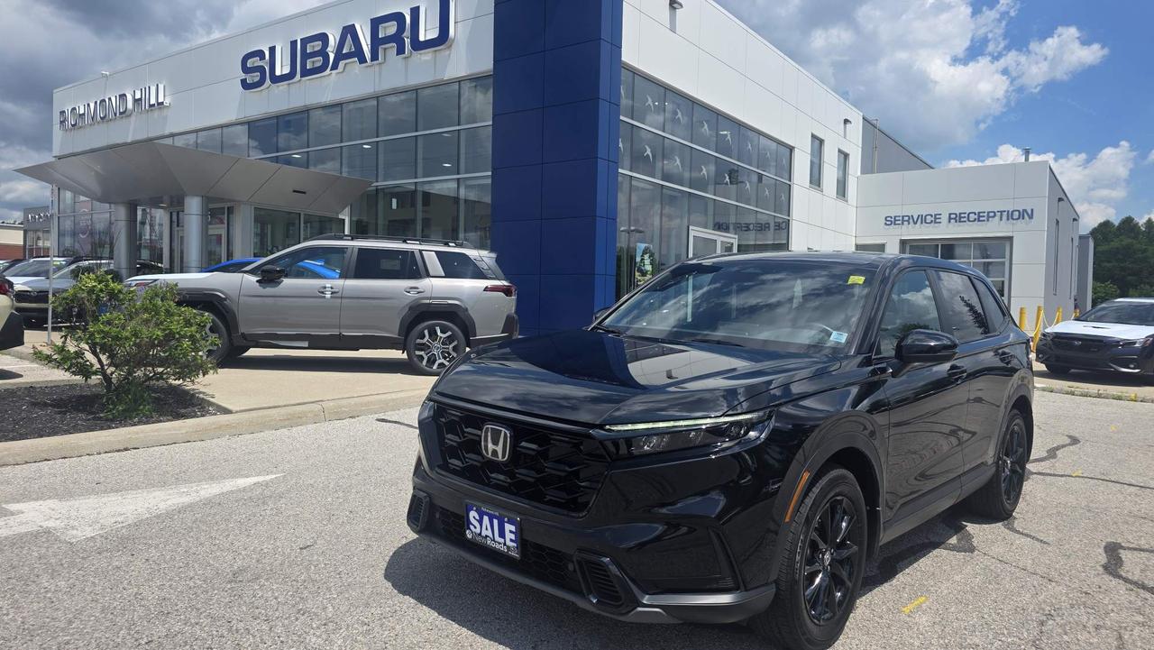 <h2><strong>Refined Efficiency: The 2026 Honda CR-V Hybrid EX-L</strong></h2>

<p>Experience the perfect harmony of sophisticated comfort and advanced hybrid performance with the <strong>2026 Honda CR-V Hybrid EX-L</strong>. Designed for drivers who demand a premium cabin experience alongside the efficiency of a hybrid powertrain, this trim offers a polished and capable ride for every journey.</p>

<h3><strong>Key Highlights</strong></h3>

<ul>
 <li>
 <p><strong>Responsive Hybrid Performance:</strong> Powered by a <strong>2.0-liter Atkinson-cycle 4-cylinder engine</strong> paired with Honda&rsquo;s two-motor hybrid system, it delivers a combined <strong>204 horsepower</strong> and <strong>247 lb-ft of torque</strong> for smooth, efficient acceleration.</p>
 </li>
 <li>
 <p><strong>Elevated Interior Luxury:</strong> Step into a refined space featuring premium <strong>leather-trimmed seating</strong> and a leather-wrapped steering wheel. Enjoy the convenience of a 10-way power-adjustable driver&rsquo;s seat with memory settings and heated front seats for year-round comfort.</p>
 </li>
 <li>
 <p><strong>Intuitive Technology:</strong> Command your drive with the <strong>9-inch central touchscreen</strong>, which includes standard wireless Apple CarPlay&reg; and wireless Android Auto&trade; connectivity. The cabin is further enhanced by a crisp, <strong>10.2-inch digital instrument display</strong> and an 8-speaker premium audio system.</p>
 </li>
 <li>
 <p><strong>Safety & Convenience:</strong> Drive with confidence thanks to the <strong>Honda Sensing&reg; suite</strong> of safety features, including Collision Mitigation Braking System&trade; (CMBS&trade;), Adaptive Cruise Control with Low-Speed Follow, and Blind Spot Information (BSI) with Cross Traffic Monitor. The addition of a power tailgate adds everyday practicality to your cargo needs.</p>
 </li>
</ul>
<p><span style=font-size:16px><span style=color:#3498db><strong>Richmond Hill&rsquo;s Subaru Certified Pre-Owned (RHSCPO)</strong></span></span></p>

<p><span style=color:#3498db><strong>Qualifying RHSCPO Vehicles (RHSCPO Badged Vehicles)</strong></span></p>

<p><strong>- &nbsp; &nbsp; &nbsp; Exclusive Selection of Pre-Owned Subaru Vehicles</strong></p>

<p><strong>- &nbsp; &nbsp; &nbsp; 160-Point Inspection By Subaru Trained Technicians and Subaru Approved Parts</strong></p>

<p><strong>- &nbsp; &nbsp; &nbsp; 24-Hour Roadside Assistance</strong></p>

<p><strong>- &nbsp; &nbsp; &nbsp; MySubaru Connected Services 1 Year Free Subscription (on equipped vehicles)</strong></p>

<p><strong>- &nbsp; &nbsp; &nbsp; Guarantee Carfax Claims Under $5000</strong></p>

<p><span style=color:#3498db><strong>RHSCPO Warranty Coverage</strong></span></p>

<p><strong>- &nbsp; &nbsp; &nbsp; Pre-Owned Subarus Up To 8 Model Years with <160,000km Include A 3 Month 5,000km Subaru Warranty</strong></p>

<p><strong>- &nbsp; &nbsp; &nbsp; Pre-Owned Subarus Up To 5 Model Years with <100,000km Still Under New Vehicle Limited Warranty Expiring Within 6 Months Or 10,000km Include A 42 Month - 70,000km Warranty From The Original In-Service Date.</strong></p>

<p><strong>- &nbsp; &nbsp; Pre-Owned Subarus Up To 5 Model Years with <100,000km With Expired New Vehicle Limited Warranty Includes a 6M - 10,000km Subaru Warranty</strong></p>

<p><em><strong><span style=font-size:16px>**All advertising pricing is for financing purchases, all cash purchases will have a&nbsp;surcharge.&nbsp;Visit us&nbsp;for our cash price or call/email us for more details.</span></strong></em></p>

<p><em><strong>***Surcharge rates based on the selling price</strong></em></p>

<p><em><strong>$0-$9,999&nbsp;= $0 </strong></em></p>

<p><em><strong>$10,000-$19,999=$1,250 </strong></em></p>

<p><em><strong>$20,000-$29,999=$1750 </strong></em></p>

<p><em><strong>$30,000-$39,999=$2200 </strong></em></p>

<p><em><strong>$40,000+ =$2500</strong></em></p>

<p><span style=color:#3498db><strong>ALL PRE-OWNED VEHICLES INCLUDE:</strong></span></p>

<p><strong>- &nbsp; &nbsp; &nbsp; Safety Certification completed to the highest standards by Factory Trained Technicians</strong></p>

<p><strong>- &nbsp; &nbsp; &nbsp; Complimentary Oil Change</strong></p>

<p><strong>- &nbsp; &nbsp; &nbsp; Full Exterior + Interior Detailing</strong></p>

<p><strong>- &nbsp; &nbsp; &nbsp; Full Tank of Gas</strong></p>

<p><strong>- &nbsp; &nbsp; &nbsp; Accident Report</strong></p>

<p><span style=color:#3498db><strong>WHY BUY FROM RICHMOND HILL SUBARU?</strong></span></p>

<p><strong>- &nbsp; &nbsp; &nbsp; All of our Pre-Owned Vehicles include our &ldquo;Market Value Pricing&rdquo;. We use sophisticated software to determine the lowest price we can sell our vehicles for, and then give you that low price right upfront.</strong></p>

<p><strong>- &nbsp; &nbsp; &nbsp; We provide a safe and easy way that you can complete your entire purchase from the comfort of your home.</strong></p>

<p><strong>- &nbsp; &nbsp; &nbsp; We do everything possible to make it fun and easy to do business with us. Read some of our Google reviews to see what our customers say.</strong></p>

<p><span style=color:#3498db><strong>FINANCING AVAILABLE:</strong></span></p>

<p><strong>- &nbsp; &nbsp; &nbsp; Trouble credit? New credit? Good credit? We offer financing for every kind of credit and we treat everyone with the same level of respect.</strong></p>

<p><strong>- &nbsp; &nbsp; &nbsp; Our Financial Service Managers will work until they secure the lowest rate possible on your behalf.</strong></p>

<p><strong>KEYS:</strong>&nbsp;All of NewRoads Richmond Hill Subaru&nbsp;Pre-Owned Vehicles are sold with one key. If we received a second&nbsp;key from the previous owner it will be included&nbsp;with the vehicle. If not, additional keys may be purchased from our Parts Department at the time of sale.</p>

<p><span style=color:#3498db><strong>We Also Offer</strong></span></p>

<p><strong>- &nbsp; &nbsp; &nbsp; Custom plans to protect your vehicle mechanically.</strong></p>

<p><strong>- &nbsp; &nbsp; &nbsp; Custom plans to protect your vehicle&rsquo;s appearance.</strong></p>

<p><strong>- &nbsp; &nbsp; &nbsp; Accessories to customize and personalize your vehicle.</strong></p>

<p><strong>**Prices are ALL IN. HST and Licensing are not included.</strong></p>

<p><strong>Richmond Hill Subaru also offers an online purchasing option so you can research, and even purchase, right from the comfort and safety of your couch, or any combination of online or in-store that works for you. Our team will be available to help you and walk you through the process.</strong></p>

<p><span style=color:#2980b9><strong>Find more details at https://www.richmondhillsubaru.com or call 905-883-3555 for more information or to make an appointment.</strong></span></p>