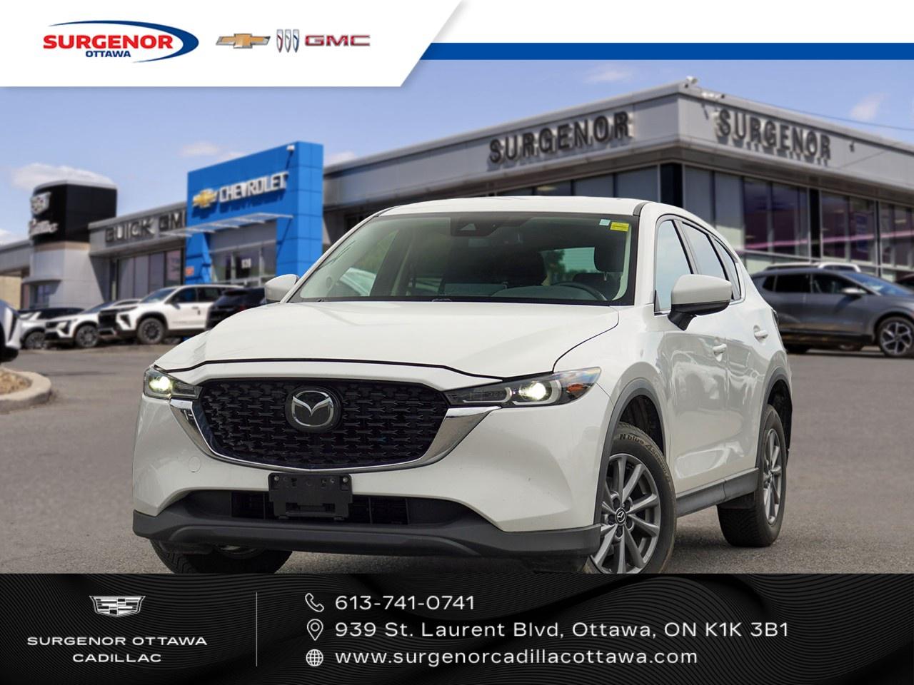 <p>Introducing the stunning 2025 Mazda CX-5 GS AWD, now available in an elegantly refined white exterior complemented by an onyx black interior. Equipped with a sophisticated automatic transmission and the reliability of all-wheel drive, this SUV ensures youll handle any road with confidence.</p><p>Immersing you in luxury and comfort, the Mazda CX-5 features alloy wheels and a suite of premium touches including heated mirrors, a leather steering wheel, and a heated steering wheel for those chilly Canadian mornings. The beautifully designed cabin with leatherette door trim and leather gear shifter material is a testament to Mazdas attention to detail.</p><p>Technology enthusiasts will appreciate the advanced smart device integration and Bluetooth connectivity, perfect for seamless entertainment and communication on the go. Safety is a top priority, with features like a backup camera, lane assist, and adaptive cruise control providing peace of mind and superior driving assistance.</p><p>Ideal for families and adventure seekers alike, this SUV also offers heated, power-adjustable seats and keyless entry, ensuring comfort and convenience for every journey. Dont miss the chance to experience these unparalleled features. Contact Surgenor Chevrolet Buick GMC Cadillac today to learn more about the 2025 Mazda CX-5 GS AWD and schedule a test drive.</p>