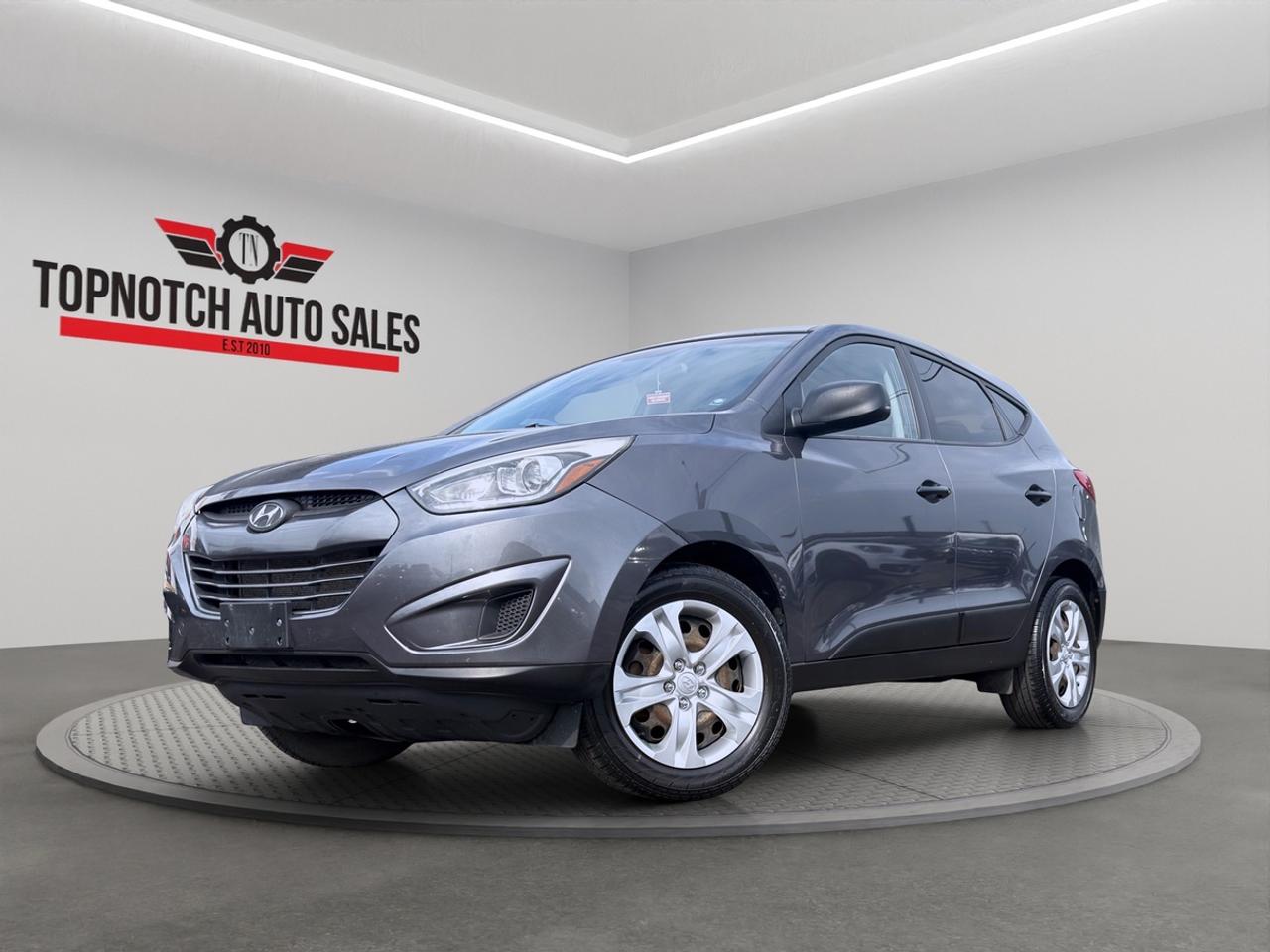 <h1>2014 Hyundai Tucson</h1><h3>Now Available at Topnotch Auto Sales Inc</h3><p>Experience practicality, comfort, and reliability with the 2014 Hyundai Tucson. This versatile compact SUV offers a smooth ride, impressive fuel efficiency, and a spacious interior designed to meet the needs of families, commuters, and active lifestyles. With its modern styling, dependable performance, and excellent value, the Tucson is ready for whatever your day brings.</p><h2>Performance & Capability</h2><p>The 2014 Hyundai Tucson delivers a balanced combination of efficiency and performance. Equipped with a responsive engine and smooth automatic transmission, it provides confident acceleration and comfortable highway cruising. Its compact size makes it easy to maneuver in urban environments while still offering the versatility and utility of an SUV.</p><p>Key performance highlights include:</p><ul><li>Fuel-efficient engine performance</li><li>Smooth automatic transmission</li><li>Comfortable ride quality</li><li>Responsive steering and handling</li><li>Excellent visibility for everyday driving</li><li>Available all-wheel drive capability (if equipped)</li></ul><p>Whether youre commuting to work or heading out on a weekend getaway, the Tucson is built to perform.</p><h2>Interior Comfort & Features</h2><p>Step inside the Tucson and enjoy a thoughtfully designed cabin featuring comfort and convenience, including:</p><ul><li>Comfortable cloth or premium seating surfaces</li><li>Heated front seats</li><li>Air conditioning</li><li>Power windows, locks, and mirrors</li><li>Adjustable drivers seat</li><li>Split-folding rear seats for flexible cargo space</li><li>Spacious cargo area for groceries, luggage, and gear</li><li>Ample interior storage compartments</li><li>Rear window defroster</li></ul><p>The Tucsons versatile interior makes it a practical choice for everyday living.</p><h2>Technology & Connectivity</h2><p>Stay connected and entertained with convenient technology features such as:</p><ul><li>AM/FM audio system</li><li>Bluetooth hands-free calling and audio streaming</li><li>USB and auxiliary input connectivity</li><li>Steering wheel-mounted audio controls</li><li>Cruise control</li><li>Satellite radio capability (where equipped)</li><li>Vehicle information display</li></ul><p>Designed with convenience in mind, the Tucson helps keep every drive enjoyable.</p><h2>Safety & Peace of Mind</h2><p>Hyundai engineered the Tucson with a variety of safety features to help protect you and your passengers, including:</p><ul><li>Electronic Stability Control (ESC)</li><li>Anti-lock Braking System (ABS)</li><li>Traction Control System</li><li>Tire Pressure Monitoring System (TPMS)</li><li>Front, side, and curtain airbags</li><li>Brake Assist System</li><li>Active head restraints</li><li>Child safety rear door locks</li></ul><p>Drive with confidence knowing the Tucson is equipped with important safety technologies.</p><h2>Vehicle Condition</h2><p>This 2014 Hyundai Tucson is in excellent, non-smoking condition both inside and out. Professionally detailed and thoroughly inspected, it reflects careful ownership and proper maintenance. Ready for its next owner.</p><h2>Why Shop with Topnotch Auto Sales Inc?</h2><p>At Topnotch Auto Sales Inc, we are dedicated to providing quality pre-owned vehicles backed by exceptional customer service. Our knowledgeable team works hard to ensure every purchase is straightforward, transparent, and stress-free.</p><h2>Flexible Financing Solutions</h2><p>We offer fast and easy financing approvals for all credit situations, including:</p><ul><li>Bad Credit</li><li>No Credit</li><li>New Credit</li><li>Previous Financial Challenges</li></ul><p>Enjoy same-day approvals, competitive interest rates, and flexible low down payment options tailored to your needs.</p><h2>Certification Option</h2><p>Choose to certify this 2014 Hyundai Tucson for only <strong>$799</strong>. Certification ensures the vehicle meets all current Ontario safety standards for added confidence and peace of mind.</p><h2>OMVIC Compliance</h2><p><strong>Important:</strong> Uncertified vehicles are offered asis and must be certified to comply with OMVIC regulations for road use. Our team is happy to guide you through the certification process and answer any questions you may have.</p><p>With over 14 years of automotive industry experience, Topnotch Auto Sales Inc has earned a reputation for integrity, quality inventory, and customer-focused service. We are proud to be your trusted destination for hassle-free vehicle shopping.</p><h3> Come Visit Us</h3><p>5455 Steeles Ave W, North York, ON M9L 1S7</p><h3> Call or Text</h3><p>416-879-7113</p>