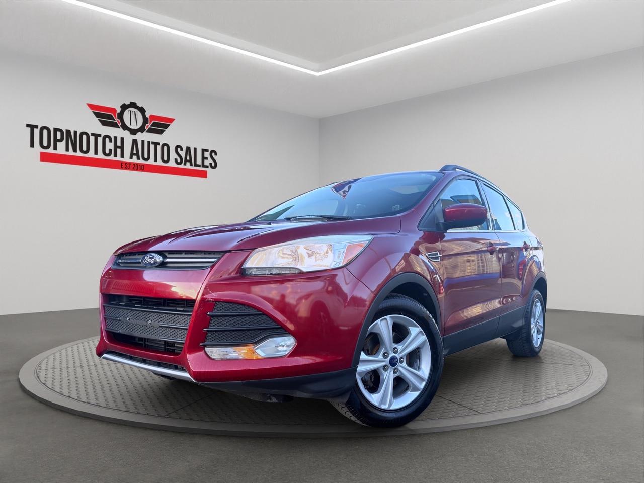 <h1>2014 Ford Escape</h1><h3>Now Available at Topnotch Auto Sales Inc</h3><p>Experience versatility, efficiency, and everyday practicality with the 2014 Ford Escape. Designed to deliver a comfortable ride, impressive cargo space, and modern convenience features, the Escape is an ideal compact SUV for families, commuters, and active lifestyles. With its stylish design, dependable performance, and flexible interior, the Escape is ready to handle your daily adventures with ease.</p><h2>Performance & Capability</h2><p>The 2014 Ford Escape offers responsive performance and excellent fuel efficiency, making it a great choice for both city driving and highway travel. Paired with a smooth automatic transmission, the Escape delivers confident handling, comfortable ride quality, and the versatility expected from a compact SUV.</p><p>Key performance highlights include:</p><ul><li>Fuel-efficient EcoBoost engine performance</li><li>Smooth automatic transmission</li><li>Comfortable ride and responsive handling</li><li>Excellent visibility for everyday driving</li><li>Easy maneuverability in urban environments</li><li>Available all-wheel drive capability (if equipped)</li><li>Balanced performance and efficiency</li></ul><p>Whether youre running errands around town or taking a weekend road trip, the Escape is built to keep up with your lifestyle.</p><h2>Interior Comfort & Features</h2><p>Step inside the Escape and enjoy a spacious cabin loaded with convenience features, including:</p><ul><li>Comfortable cloth or premium seating surfaces</li><li>Heated front seats (where equipped)</li><li>Air conditioning or automatic climate control (where equipped)</li><li>Power windows, locks, and mirrors</li><li>Adjustable drivers seat</li><li>Split-folding rear seats for flexible cargo configurations</li><li>Generous cargo capacity for luggage, groceries, and gear</li><li>Multiple storage compartments throughout the cabin</li><li>Rear window defroster</li></ul><p>The Escapes thoughtfully designed interior provides comfort and practicality for both driver and passengers.</p><h2>Technology & Connectivity</h2><p>Stay connected and entertained with modern technology features such as:</p><ul><li>Touchscreen infotainment system (where equipped)</li><li>Bluetooth hands-free calling and audio streaming</li><li>USB and auxiliary connectivity</li><li>Steering wheel-mounted audio and cruise controls</li><li>SYNC voice-activated communication system</li><li>Satellite radio capability (where equipped)</li><li>Rearview camera (where equipped)</li><li>Vehicle information display</li></ul><p>The Escape delivers the technology and convenience todays drivers expect.</p><h2>Safety & Peace of Mind</h2><p>Ford engineered the 2014 Escape with advanced safety systems designed to help protect occupants, including:</p><ul><li>Anti-lock Braking System (ABS)</li><li>Electronic Stability Control (ESC)</li><li>Traction Control System</li><li>Tire Pressure Monitoring System (TPMS)</li><li>Front, side, and side-curtain airbags</li><li>Brake Assist</li><li>Child safety rear door locks</li><li>AdvanceTrac® stability management system</li></ul><p>Drive confidently knowing the Escape is equipped with important safety technologies.</p><h2>Vehicle Condition</h2><p>This 2014 Ford Escape is in excellent, non-smoking condition both inside and out. Professionally detailed and thoroughly inspected, it reflects careful ownership and proper maintenance. Ready for its next owner.</p><h2>Why Shop with Topnotch Auto Sales Inc?</h2><p>At Topnotch Auto Sales Inc, we are committed to providing quality pre-owned vehicles backed by exceptional customer service. Our knowledgeable team works hard to ensure every purchase is straightforward, transparent, and stress-free.</p><h2>Flexible Financing Solutions</h2><p>We offer quick and easy financing approvals for all credit situations, including:</p><ul><li>Bad Credit</li><li>No Credit</li><li>New Credit</li><li>Previous Financial Challenges</li></ul><p>Enjoy same-day approvals, competitive interest rates, and flexible low down payment options tailored to your needs.</p><h2>Certification Option</h2><p>Choose to certify this 2014 Ford Escape for only <strong>$799</strong>. Certification ensures the vehicle meets all current Ontario safety standards for added confidence and peace of mind.</p><h2>OMVIC Compliance</h2><p><strong>Important:</strong> Uncertified vehicles are offered asis and must be certified to comply with OMVIC regulations for road use. Our team is happy to guide you through the certification process and answer any questions you may have.</p><p>With over 14 years of automotive industry experience, Topnotch Auto Sales Inc has earned a reputation for integrity, quality inventory, and customer-focused service. We are proud to be your trusted destination for hassle-free vehicle shopping.</p><h3> Come Visit Us</h3><p>5455 Steeles Ave W, North York, ON M9L 1S7</p><h3> Call or Text</h3><p>416-879-7113</p>