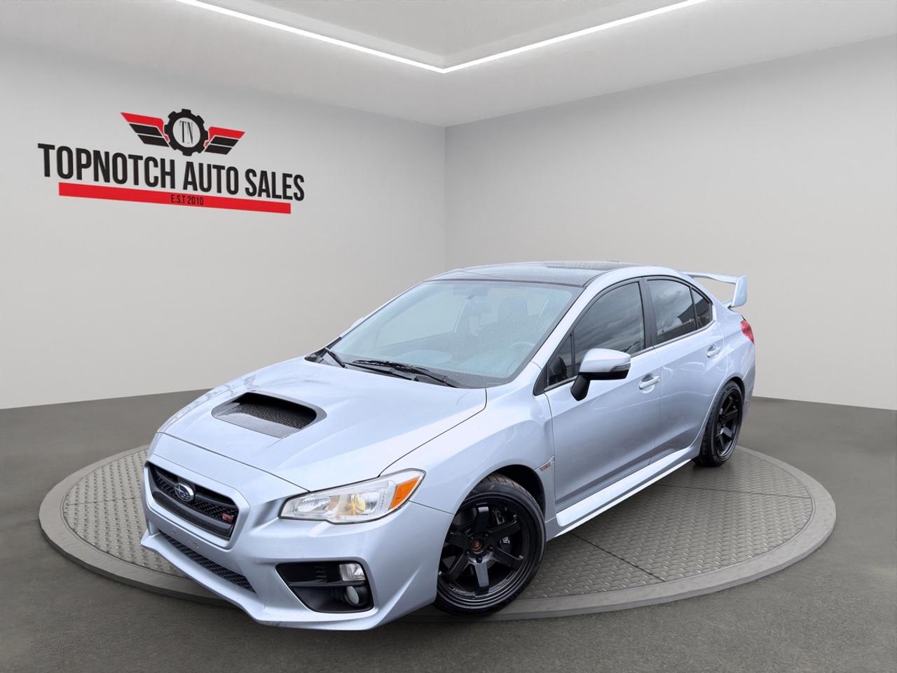 <p><strong>2015 Subaru WRX STI</strong></p><p>Now Available at Topnotch Auto Sales Inc</p><p>Unleash pure performance with the 2015 Subaru WRX STI, now available at Topnotch Auto Sales Inc. Built for driving enthusiasts, this iconic sports sedan delivers aggressive styling, rally-inspired engineering, and thrilling performance that sets it apart from the competition.</p><p>With its unmistakable design and legendary AWD system, the WRX STI is made for those who crave excitement behind the wheel.</p><p><br></p><h3><strong>Performance & Driving Experience</strong></h3><p>Powered by a turbocharged 2.5L BOXER engine paired with a 6-speed manual transmission, the WRX STI delivers exhilarating power and precision handling. Subarus Symmetrical All-Wheel Drive system provides exceptional grip and control in all road conditions.</p><p>This car is engineered for performance, offering sharp cornering, quick acceleration, and a true driver-focused experience.</p><p><br></p><h3><strong>Interior & Driver-Focused Cabin</strong></h3><p>Step into a sporty interior designed with the driver in mind.</p><p><strong>Interior Highlights:</strong></p><ul><li>Sport bucket seats with STI branding</li><li>Heated front seats</li><li>Leather and suede upholstery</li><li>Performance-inspired flat-bottom steering wheel</li><li>Aluminum sport pedals</li><li>Foldable rear seats for added practicality</li></ul><h3><strong>Technology & Features</strong></h3><p>Enjoy a balance of performance and modern convenience.</p><p><strong>Technology Features:</strong></p><ul><li>Touchscreen infotainment system</li><li>Bluetooth connectivity</li><li>Premium sound system</li><li>Backup camera</li><li>USB and auxiliary inputs</li><li>Steering wheel-mounted controls</li></ul><h3><strong>Safety & Control</strong></h3><p>Built with performance and safety in mind.</p><p><strong>Safety Highlights:</strong></p><ul><li>Subaru Symmetrical AWD</li><li>Vehicle Dynamics Control (stability control)</li><li>Anti-lock braking system (ABS)</li><li>Traction control</li><li>Multiple airbags</li><li>Rearview camera</li></ul><h3><strong>Excellent Condition</strong></h3><p>This WRX STI has been well maintained and is clean inside and out. Fully inspected and professionally detailed  ready for its next owner.</p><p><br></p><h3><strong>Why Choose Topnotch Auto Sales Inc?</strong></h3><p>With over 14 years of experience, we deliver quality vehicles and a hassle-free buying experience you can trust.</p><p><br></p><h3><strong>Flexible Financing Options</strong></h3><p>We work with all types of credit:</p><ul><li>Fast approvals</li><li>Same-day financing available</li><li>Low down payment options</li></ul><h3><strong>Certification Available</strong></h3><p>For only $799, this vehicle can be certified to meet Ontario safety standards  giving you extra confidence.</p><p><br></p><h3><strong>OMVIC Notice</strong></h3><p>This vehicle is being sold <strong>asis</strong> unless certified, as per OMVIC regulations. Ask us for details.</p><p><br></p><p> <strong>Visit Us:</strong></p><p>5455 Steeles Ave W, North York, ON M9L 1S7</p><p> <strong>Call or Text:</strong></p><p>416-879-7113</p>