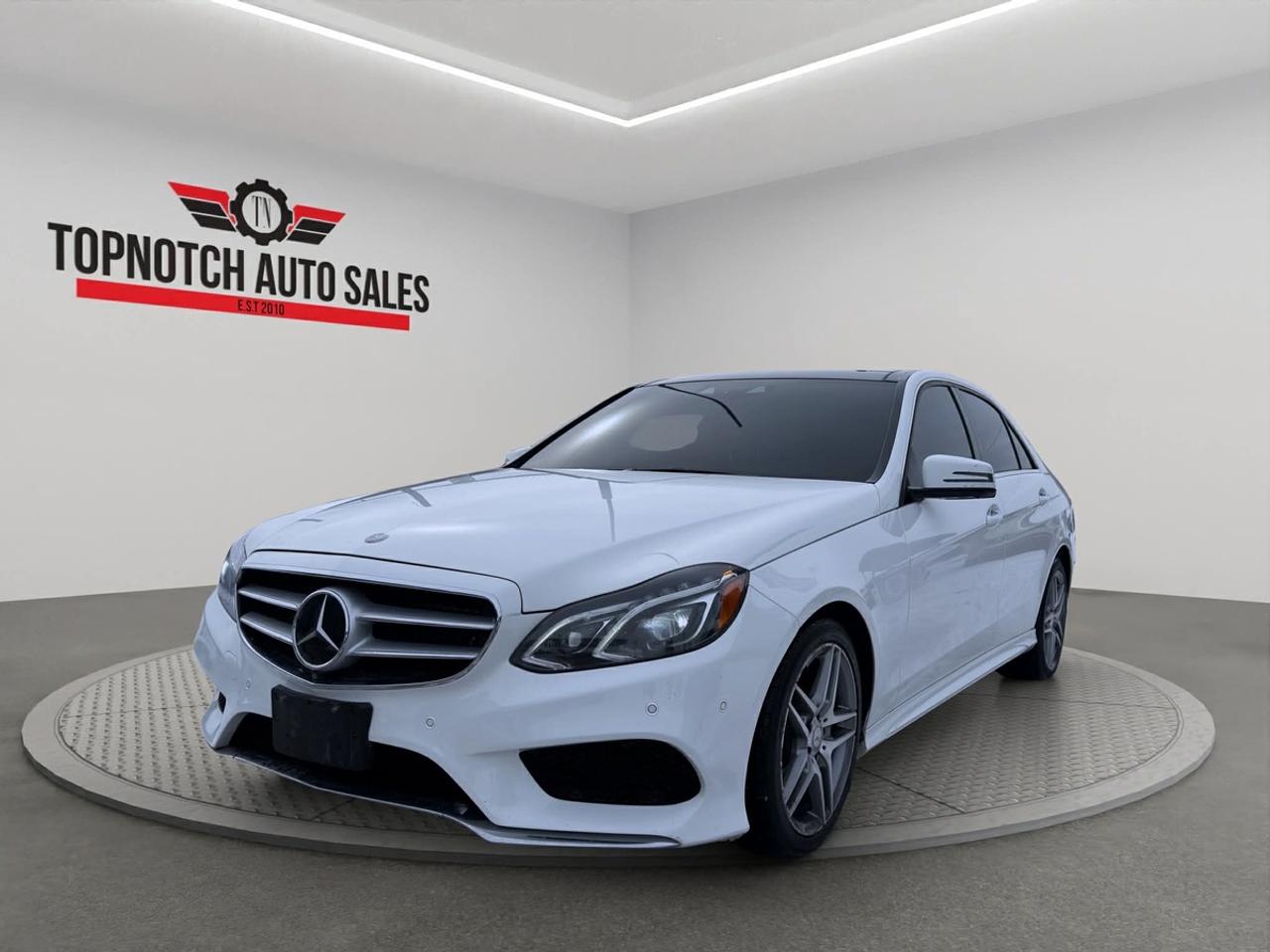 <h2>2016 Mercedes-Benz E-Class | Premium Luxury Sedan | 5-Passenger Capacity | Backup Camera | Bluetooth Connectivity | Alloy Wheels | Automatic Transmission</h2><p><br></p><p>Experience the epitome of luxury and advanced engineering with the 2016 <strong>Mercedes-Benz E-Class</strong>, now available at <strong>Topnotch Auto Sales Inc</strong>. This exceptional sedan proudly represents the renowned heritage of Mercedes-Benz, blending sophisticated styling, a meticulously sculpted interior, and cutting-edge technology. Designed to elevate every journey, the E-Class offers an unrivalled driving experience defined by comfort, refinement, and superior attention to detail. Whether youre seeking the perfect executive commuter or a family-friendly luxury vehicle, this E-Class embodies versatility, prestige, and innovation for drivers who expect the very best.</p><p><br></p><p><br></p><h2>Performance & Driving Dynamics</h2><p><br></p><p>The 2016 Mercedes-Benz E-Class is powered by a responsive and fuel-efficient engine, delivering a harmonious balance of power and efficiency for any driving scenario. Paired with a sophisticated automatic transmission, this sedan offers seamless gear shifts and remarkable driving poise. The rear-wheel-drive (RWD) system provides optimal weight distribution for exceptional handling and balance, promising both spirited city maneuvering and smooth, composed highway cruising. Engineered for the passionate driver, the E-Class features Mercedes-Benzs time-honoured commitment to precision, offering quiet acceleration, refined ride quality, and outstanding road stability at any speed.</p><p><br></p><h3>Performance Highlights:</h3><p><br></p><ul><li><br></li><li>Robust & Economical Engine for a dynamic yet efficient driving experience</li><li><br></li><li>Effortless Automatic Transmission with intelligent gear changes</li><li><br></li><li>Rear-Wheel Drive (RWD) for superior balance and agility</li><li><br></li><li>Advanced Suspension System for unrivaled comfort and control</li><li><br></li><li>Precision Steering for assured maneuverability</li><li><br></li><li>Striking Alloy Wheels for enhanced style and reliability</li><li><br></li></ul><p><br></p><p><br></p><h2>Interior Comfort & Opulence</h2><p><br></p><p>Open the doors to a truly inviting 5-passenger cabin, where every surface is tailored for superior comfort and elegance. The 2016 E-Class features plush leatherette or available genuine leather seating with fine stitching, complemented by exquisite wood or brushed aluminum trim accents. The spacious interior ensures ample legroom for all passengers, creating a tranquil, first-class setting for both short commutes and extended trips. Enjoy the convenience of 8-way power-adjustable front seats, dual-zone automatic climate control, and thoughtful amenities such as power windows, door locks, and heated side mirrors. With significant trunk space and refined finishes throughout, every journey is a luxurious experience in the E-Class.</p><p><br></p><h3>Interior Highlights:</h3><p><br></p><ul><li><br></li><li>Available Premium Leatherette or Genuine Leather Upholstery</li><li><br></li><li>8-Way Power-Adjustable Front Seats for individualized comfort</li><li><br></li><li>Dual-Zone Automatic Climate Control for personalized cabin environments</li><li><br></li><li>Generously Sized Rear Seating for enhanced comfort</li><li><br></li><li>Power Features including Windows, Door Locks, and Heated Mirrors</li><li><br></li><li>Sophisticated Wood or Aluminum Interior Accents</li><li><br></li><li>Substantial Trunk Capacityperfect for luggage, groceries, and more</li><li><br></li><li>Every feature carefully designed to deliver Mercedes-Benz signature luxury</li><li><br></li></ul><p><br></p><p><br></p><h2>Technology & Connectivity</h2><p><br></p><p>Stay connected, productive, and entertained with the E-Classs suite of cutting-edge technology and infotainment features. A central multimedia display provides smooth, intuitive access to all infotainment and vehicle settings. Operate calls, music, and navigation easily with Bluetooth connectivity, while the premium audio system envelops all occupants in concert-level sound. Multiple media input options and steering wheel-mounted controls keep you in charge without taking your eyes off the road, ensuring a safe and engaging driving experience for every journey.</p><p><br></p><h3>Technology Features:</h3><p><br></p><ul><li><br></li><li>Bluetooth Hands-Free Communication and Wireless Audio Streaming</li><li><br></li><li>Integrated Backup Camera for effortless and secure parking</li><li><br></li><li>Central Display for vehicle settings, audio, and navigation control</li><li><br></li><li>High-Fidelity Premium Sound System</li><li><br></li><li>Convenient Steering-Wheel Mounted Audio, Phone, and Voice Controls</li><li><br></li><li>Versatile Media Inputs: USB, AUX, SD Card</li><li><br></li><li>Smart technology for connectivity, entertainment, and peace of mind on every drive</li><li><br></li></ul><p><br></p><p><br></p><h2>Advanced Safety & Peace of Mind</h2><p><br></p><p>Safety is a top priority in the Mercedes-Benz E-Class, reflecting decades of engineering expertise dedicated to occupant protection. This sedan comes equipped with cutting-edge safety and driver assistance features designed to safeguard you and your passengers under all driving circumstances. Robust structural integrity, comprehensive airbag coverage, and advanced electronic systems all work together for your confidence and security behind the wheel.</p><p><br></p><h3>Safety Highlights:</h3><p><br></p><ul><li><br></li><li>Reverse Backup Camera for clear, easy maneuvering</li><li><br></li><li>Electronic Stability and Traction Control Systems</li><li><br></li><li>Anti-Lock Braking System (ABS) for optimal stopping power</li><li><br></li><li>Comprehensive Front and Side Airbag System</li><li><br></li><li>Emergency Brake Assist Technology</li><li><br></li><li>Tire Pressure Monitoring System for added safety</li><li><br></li><li>Fully engineered to be your most trusted on-road companion</li><li><br></li></ul><p><br></p><p><br></p><h2>Impeccable Vehicle Condition</h2><p><br></p><p>This 2016 Mercedes-Benz E-Class has undergone a meticulous multi-point inspection and has been thoroughly reconditioned by our certified automotive technicians. Maintenance and service records are available for your review, offering full transparency and confidence in your next automotive investment. Both the interior and exterior showcase the pride of previous ownership, delivering a pre-owned vehicle experience that feels genuinely like new.</p><p><br></p><p><br></p><h2>Why Buy from Topnotch Auto Sales Inc?</h2><p><br></p><p>With a proud legacy of over 14 years serving our valued customers, <strong>Topnotch Auto Sales Inc</strong> is committed to providing only the highest standard of pre-owned vehicles and customer service. Our dedicated staff strive to deliver a seamless, honest, and enjoyable buying experienceensuring your peace of mind and satisfaction from start to finish.</p><p><br></p><p><br></p><h2>Flexible & Accessible Financing Solutions</h2><p><br></p><p>Regardless of your financial background or credit score, we offer a full range of financing options designed to get you on the road quickly and comfortably. Whether you have excellent credit, are new to Canada, or rebuilding your finances, our financing specialists are here to help with rapid approvals, competitive rates, and affordable down payment solutions tailored to your needs.</p><p><br></p><p><br></p><h2>Optional Certification for Your Assurance</h2><p><br></p><p>For added peace of mind, take advantage of our available certification package for just $799, ensuring your vehicle meets strict Ontario provincial safety standards. This offering is designed to give our customers additional confidence with their pre-owned purchase.</p><p><br></p><p><br></p><h2>OMVIC Compliance Notice</h2><p><br></p><p>In alignment with OMVIC regulations, our vehicles are offered as-is unless you opt for certification. Our informed team is ready to guide you seamlessly through the certification process, should you wish to enhance your purchase with this security.</p><p><br></p><p><br></p><p> <strong>Visit Us At:</strong></p><p>5455 Steeles Ave W, North York, ON M9L 1S7</p><p><br></p><p> <strong>Call or Text:</strong></p><p><br></p><h2>416-879-7113</h2>