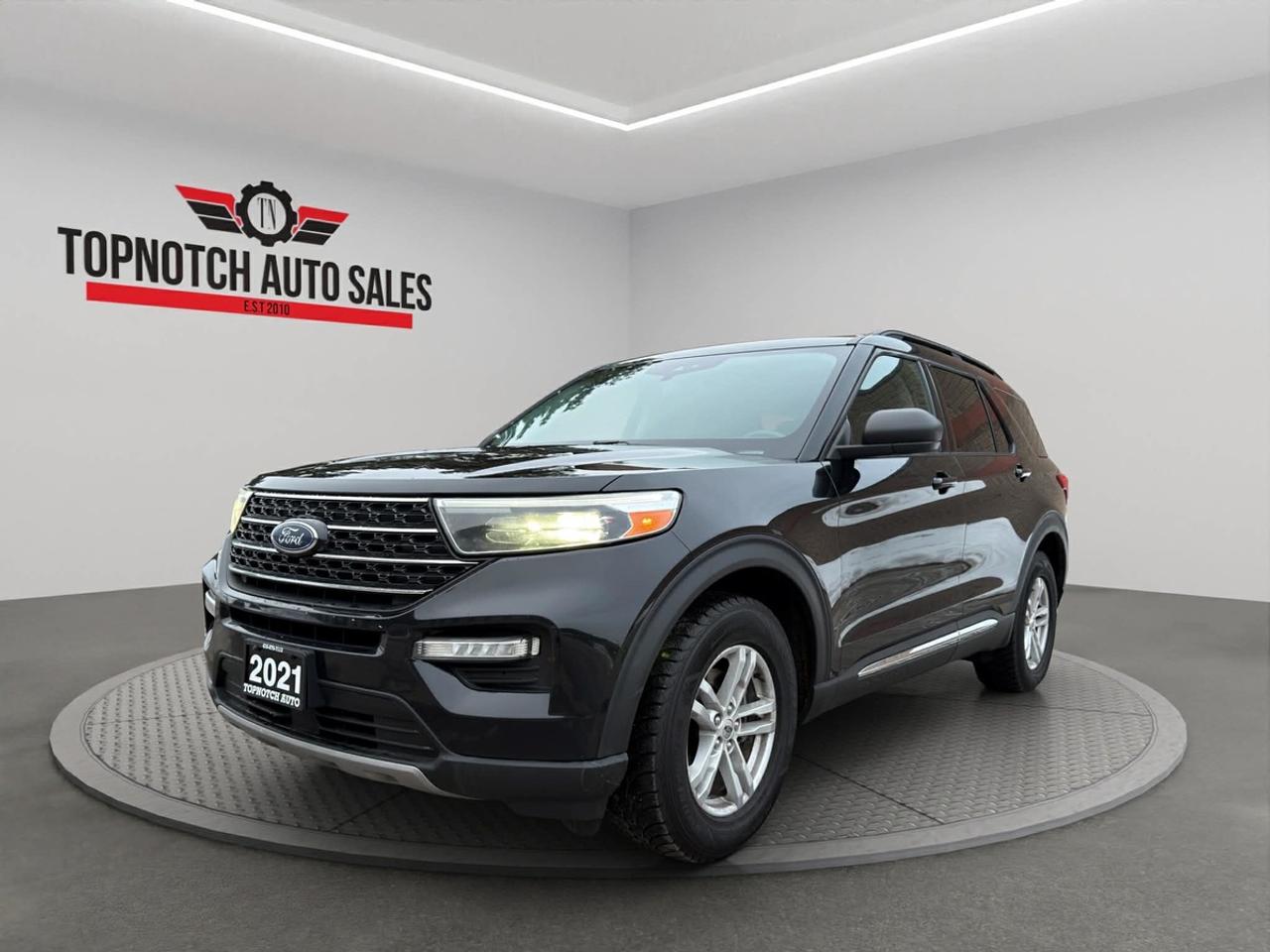 <h2>2021 Ford Explorer XLT</h2><p><br></p><p><strong>Now available at Topnotch Auto Sales Inc</strong></p><p><br></p><p>Experience the perfect balance of sophistication, capability, and modern convenience with the <strong>2021 Ford Explorer XLT</strong>. This versatile midsize SUV is thoughtfully engineered for todays active families, offering exceptional comfort, dynamic performance, and the latest in advanced safety and connectivity. Whether youre navigating city streets, embarking on a weekend adventure, or tackling unpredictable Canadian winters, the Explorer XLT delivers unmatched reliability and driving pleasure.</p><p><br></p><p><br></p><h3>Performance & Capability</h3><p><br></p><p>Beneath the hood, the Explorer XLT features a <strong>powerful and fuel-efficient engine</strong> paired with <strong>Intelligent All-Wheel Drive</strong> capabilities. This system ensures confident traction and smooth, responsive handling in a variety of driving conditions. From daily commutes to family road trips, this SUV is engineered to provide optimum performance, stability, and control, so you always drive with confidence whatever the journey brings.</p><p><br></p><p><br></p><h3>Interior Comfort & Features</h3><p><br></p><p>Step inside to find a spacious, meticulously designed cabin loaded with premium comforts and practical amenities, including:</p><p><br></p><ul><li><br></li><li>Power-adjustable drivers seat for a custom driving position</li><li><br></li><li>High-quality premium cloth upholstery</li><li><br></li><li>Dual-zone automatic climate control for personalized comfort</li><li><br></li><li>Heated front seats for added warmth on cold days</li><li><br></li><li>Flexible three-row seating with ample cargo space for passengers and gear</li><li><br></li></ul><p><br></p><p>The Explorer XLTs interior is crafted for both comfort and adaptability, making every drive enjoyable and accommodating your lifestyle with ease.</p><p><br></p><p><br></p><h3>Technology & Connectivity</h3><p><br></p><p>Stay effortlessly connected on the go with Fords advanced infotainment offerings, featuring:</p><p><br></p><ul><li><br></li><li>User-friendly touchscreen display</li><li><br></li><li>Apple CarPlay and Android Auto compatibility</li><li><br></li><li>Bluetooth hands-free connectivity</li><li><br></li><li>Multiple USB ports for convenient device charging</li><li><br></li><li>Steering-wheel-mounted audio and phone controls</li><li><br></li></ul><p><br></p><p>Control your entertainment and communications seamlessly, ensuring you and your passengers stay informed, entertained, and connected wherever the road takes you.</p><p><br></p><p><br></p><h3>Safety & Peace of Mind</h3><p><br></p><p>Drive with assurance knowing the 2021 Ford Explorer XLT is loaded with comprehensive safety features designed to protect you and your loved ones, such as:</p><p><br></p><ul><li><br></li><li>Clear rearview camera for easier parking and reversing</li><li><br></li><li>Blind-spot information system</li><li><br></li><li>Lane-keeping assist to help you stay on track</li><li><br></li><li>Pre-collision assist with automatic emergency braking for added protection</li><li><br></li><li>Adaptive cruise control (if equipped) for stress-free highway driving</li><li><br></li><li>Advanced ABS, traction, and stability control systems</li><li><br></li><li>Multiple airbags throughout the cabin for enhanced safety</li><li><br></li></ul><p><br></p><p>Every drive is backed by technology that puts your safety first.</p><p><br></p><p><br></p><h3>Vehicle Condition</h3><p><br></p><p>This Explorer XLT is presented in a <strong>clean, non-smoking condition</strong>, showing pride of ownership and attentive upkeep, both inside and out. It has been carefully maintained and is prepared to provide years of dependable service to its next owner.</p><p><br></p><p><br></p><h2>Topnotch Auto Sales  Your Trusted Source for Quality Pre-Owned Vehicles</h2><p><br></p><p>When youre searching for a reliable pre-owned vehicle, trust <strong>Topnotch Auto Sales Inc</strong> to deliver excellent value, a broad selection of vehicles, and <strong>flexible financing solutions</strong> tailored to your needs.</p><p><br></p><p><br></p><h3>Financing Available</h3><p><br></p><p>Our financing experts work with <strong>all credit situations</strong>, offering quick approvals for everyonewhether you have good credit, bad credit, no credit, or are recovering from previous credit challenges. Benefit from same-day approvals and low down payment options designed to fit your budget.</p><p><br></p><p><br></p><h3>Certification Option</h3><p><br></p><p>For added confidence, upgrade to a certified vehicle for just <strong>${799}</strong>. Certification ensures your vehicle undergoes a comprehensive inspection and meets all Ontario safety standards.</p><p><br></p><p><br></p><h3>OMVIC Compliance</h3><p><br></p><p>In compliance with OMVIC regulations, our uncertified vehicles are sold <strong>asis</strong> and require certification to be driven on Ontario roads. Ask our team about certification options to ensure your peace of mind.</p><p><br></p><p>With <strong>over 14 years of experience</strong>, Topnotch Auto Sales is dedicated to delivering exceptional customer service and a <strong>seamless car-buying experience</strong>.</p><p><br></p><p><br></p><p><br></p><p><br></p><p> <strong>Visit us at:</strong></p><p><br></p><p>5455 Steeles Ave W, North York, ON M9L 1S7</p><p><br></p><p> <strong>Call or Text:</strong></p><p><br></p><p>416-879-7113</p>