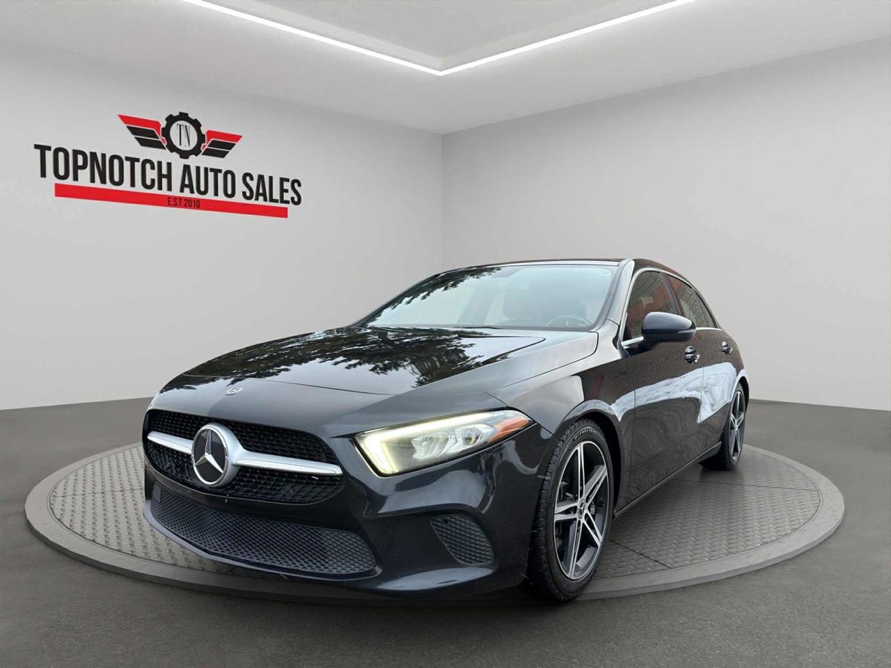 <h2>2019 Mercedes-Benz A-Class A250</h2><p><br></p><p><strong>Now Available at Topnotch Auto Sales Inc</strong></p><p><br></p><p>Discover the perfect blend of elegance, advanced technology, and agile performance with the 2019 Mercedes-Benz A-Class A250. Meticulously engineered to set a new standard in compact luxury, the A250 exudes sophistication with a streamlined exterior design, superior craftsmanship, and an abundance of premium features that enhance every mile. Whether youre navigating your daily commute or embarking on a weekend journey, this Mercedes-Benz provides exceptional comfort, impressive efficiency, and an unmistakably distinguished presence on the road.</p><p><br></p><p><br></p><p><br></p><h2>Performance & Capability</h2><p><br></p><p>The 2019 Mercedes-Benz A250 comes equipped with a responsive turbocharged engine and a seamless automatic transmission, offering exhilarating acceleration and precise control. Experience a remarkable balance of dynamic handling and ride comfort, thanks to its finely tuned suspension and responsive steering. Designed for versatility, the A250 performs effortlessly in urban environments while delivering smooth, confident highway driving. Enjoy spirited performance without compromising fuel efficiency, making every drive both thrilling and economical.</p><p><br></p><p><br></p><p><br></p><h2>Interior Comfort & Features</h2><p><br></p><p>Step inside to experience a cutting-edge, driver-centric cabin that exemplifies Mercedes-Benz luxury and innovation. Interior features include:</p><p><br></p><ul><li><br></li><li>Premium seating for up to five with top-tier upholstery for superior comfort and support</li><li><br></li><li>Dual-zone automatic climate control, allowing personalized temperature settings for driver and passengers</li><li><br></li><li>Convenient power-operated windows, locks, and mirrors for effortless control</li><li><br></li><li>Generous trunk space and smart storage compartments to accommodate your everyday needs</li><li><br></li><li>Elegant interior trims and customizable ambient lighting to create a refined, inviting atmosphere</li><li><br></li></ul><p><br></p><p>The interior of the A250 seamlessly combines comfort, style, and advanced practicality for an enhanced driving experience on every journey.</p><p><br></p><p><br></p><p><br></p><h2>Technology & Connectivity</h2><p><br></p><p>Stay effortlessly connected and entertained with the latest in automotive technology:</p><p><br></p><ul><li><br></li><li>Dual high-resolution digital displays with an intuitive Mercedes-Benz infotainment system</li><li><br></li><li>Bluetooth connectivity for hands-free calling and seamless wireless audio streaming</li><li><br></li><li>Multiple USB ports to keep all your devices charged and ready</li><li><br></li><li>Steering-wheel-mounted controls for safe, convenient access to essential functions</li><li><br></li><li>High-fidelity sound system delivering premium, immersive audio clarity</li><li><br></li></ul><p><br></p><p>The A-Class keeps you in command and connected, prioritizing your convenience and enjoyment behind the wheel.</p><p><br></p><p><br></p><p><br></p><h2>Safety & Peace of Mind</h2><p><br></p><p>With a focus on your security, the 2019 Mercedes-Benz A250 is equipped with advanced safety features, including:</p><p><br></p><ul><li><br></li><li>Rearview camera for improved visibility and easier parking maneuvers</li><li><br></li><li>Integrated traction control and electronic stability systems for assured handling in all conditions</li><li><br></li><li>Anti-lock braking system (ABS) for responsive and dependable braking</li><li><br></li><li>Comprehensive airbag coverage throughout the cabin to protect every occupant</li><li><br></li><li>Tire pressure monitoring system for optimal safety and performance on the road</li><li><br></li></ul><p><br></p><p>Drive confidently knowing this Mercedes-Benz is engineered to uphold the highest safety standards at every turn.</p><p><br></p><p><br></p><p><br></p><h2>Vehicle Condition</h2><p><br></p><p>This 2019 Mercedes-Benz A-Class A250 presents in outstanding, non-smoking condition inside and out. The vehicle has been meticulously detailed and thoroughly inspected, demonstrating attentive maintenance and true pride of ownership. You can count on long-lasting reliability and exceptional quality with this model.</p><p><br></p><p><br></p><p><br></p><h2>Why Shop with Topnotch Auto Sales?</h2><p><br></p><p>At Topnotch Auto Sales Inc, we pride ourselves on delivering only high-caliber pre-owned vehicles and a customer-first experience. Our knowledgeable, friendly team is dedicated to making your car-buying journey straightforward, transparent, and hassle-free from start to finish.</p><p><br></p><p><br></p><p><br></p><h2>Flexible Financing Solutions</h2><p><br></p><p>We provide quick financing approvals for <strong>all credit backgrounds</strong>including no credit, new credit, bad credit, or previous repossessions. Take advantage of our same-day approvals and minimal down payment options, designed to help you get behind the wheel sooner.</p><p><br></p><p><br></p><p><br></p><h2>Certification Option</h2><p><br></p><p>Upgrade your 2019 Mercedes-Benz A250 with certification for <strong>just $799</strong>, ensuring compliance with all Ontario safety requirements and greater confidence every time you drive.</p><p><br></p><p><br></p><p><br></p><h2>OMVIC Compliance</h2><p><br></p><p><strong>Please note:</strong> Uncertified vehicles are sold in asis condition and require certification for road use per OMVIC regulations. Our team is ready to assist with the certification process to guarantee your safety and satisfaction.</p><p><br></p><p><br></p><p><br></p><p>With over <strong>14 years of dedicated industry experience</strong>, Topnotch Auto Sales Inc has built a loyal reputation for integrity, quality vehicles, and customer-driven service. We are your trusted partner for a seamless automotive shopping experience in <strong>{location}</strong>.</p><p><br></p><p><br></p><p><br></p><p> <strong>Visit Us At:</strong></p><p><br></p><p>5455 Steeles Ave W, North York, ON M9L 1S7</p><p><br></p><p> <strong>Call or Text:</strong></p><p><br></p><p>416-879-7113</p>