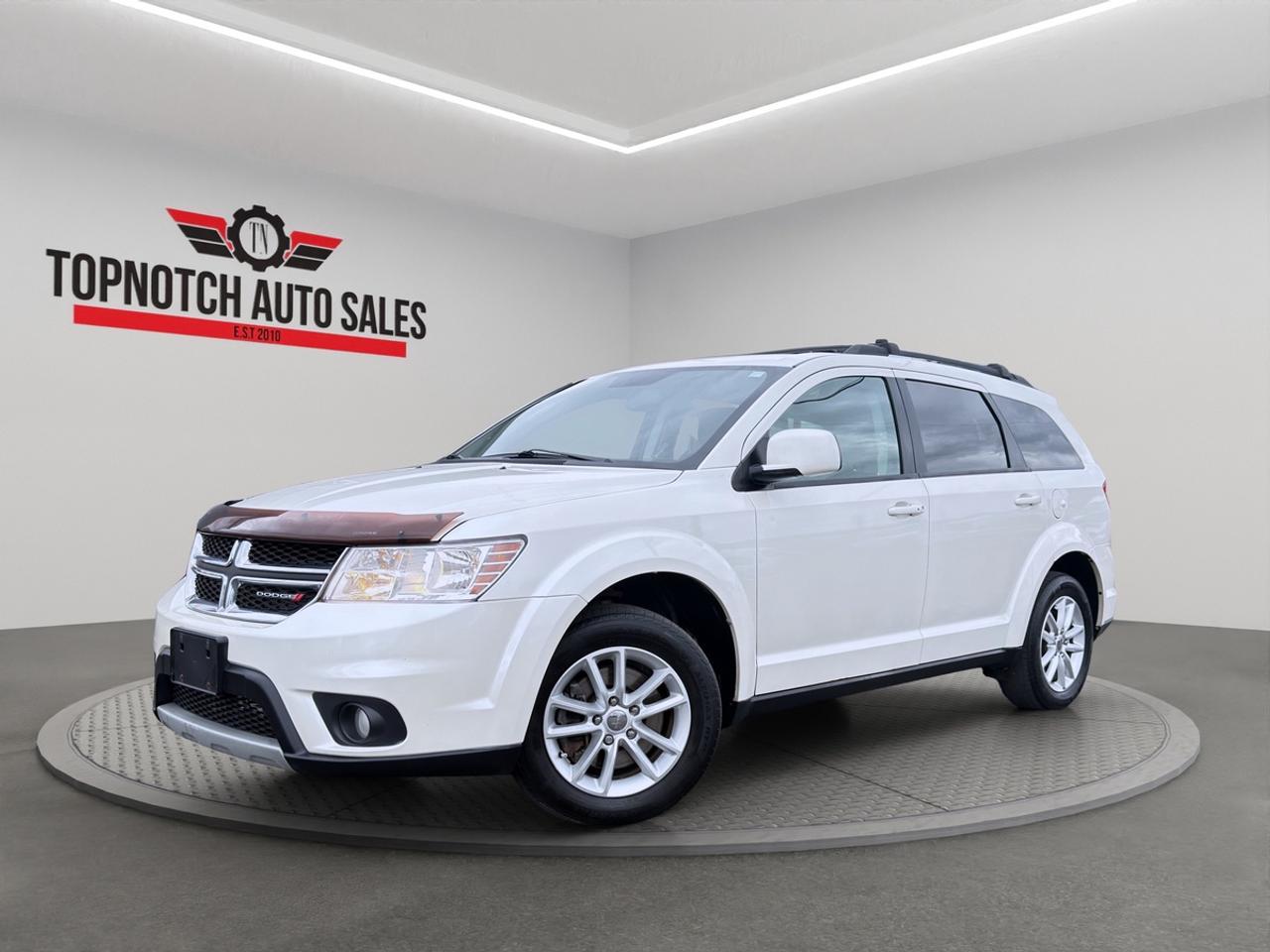 <p><strong>2015 Dodge Journey SXT</strong></p><p>Now Available at Topnotch Auto Sales Inc</p><p>Discover practicality, comfort, and value with the 2015 Dodge Journey SXT, now available at Topnotch Auto Sales Inc. This versatile SUV is perfect for families or daily drivers looking for a spacious interior and reliable performance at an affordable price.</p><p>With its bold design and flexible seating, the Journey is built to handle both everyday commutes and weekend trips with ease.</p><p><br></p><h3><strong>Performance & Driving Experience</strong></h3><p>Equipped with a strong V6 engine and smooth automatic transmission, the 2015 Journey SXT offers a balanced mix of power and efficiency. Its comfortable ride and stable handling make it ideal for city driving and highway cruising.</p><p><br></p><h3><strong>Interior Comfort & Space</strong></h3><p>Step inside a roomy cabin designed with convenience and flexibility in mind.</p><p><strong>Interior Highlights:</strong></p><ul><li>Seating for up to 7 passengers</li><li>Dual-zone climate control</li><li>Comfortable premium cloth seating</li><li>Power-adjustable drivers seat</li><li>Fold-flat second and third-row seats</li><li>Spacious cargo area</li><li>Keyless entry</li></ul><h3><strong>Technology & Connectivity</strong></h3><p>Enjoy a range of features that keep you connected and entertained on the road.</p><p><strong>Technology Features:</strong></p><ul><li>Touchscreen infotainment system</li><li>Bluetooth hands-free calling and audio</li><li>USB and auxiliary inputs</li><li>Steering wheel-mounted controls</li><li>Push-button start</li></ul><h3><strong>Safety & Reliability</strong></h3><p>Drive with confidence thanks to essential safety features.</p><p><strong>Safety Highlights:</strong></p><ul><li>Anti-lock braking system (ABS)</li><li>Electronic stability control</li><li>Traction control</li><li>Multiple airbags</li><li>Tire pressure monitoring system</li></ul><h3><strong>Excellent Condition</strong></h3><p>This vehicle has been well maintained and is clean inside and out. Fully inspected and professionally detailed  ready for its next owner.</p><p><br></p><h3><strong>Why Choose Topnotch Auto Sales Inc?</strong></h3><p>With over 14 years of experience, we provide quality pre-owned vehicles and a smooth, hassle-free buying experience.</p><p><br></p><h3><strong>Flexible Financing Options</strong></h3><p>We work with all types of credit:</p><ul><li>Fast approvals</li><li>Same-day financing available</li><li>Low down payment options</li></ul><h3><strong>Certification Available</strong></h3><p>For only $799, this vehicle can be certified to meet Ontario safety standards for added peace of mind.</p><p><br></p><h3><strong>OMVIC Notice</strong></h3><p>This vehicle is being sold <strong>asis</strong> unless certified, as per OMVIC regulations. Ask us for more details.</p><p><br></p><p> <strong>Visit Us:</strong></p><p>5455 Steeles Ave W, North York, ON M9L 1S7</p><p> <strong>Call or Text:</strong></p><p>416-879-7113</p>