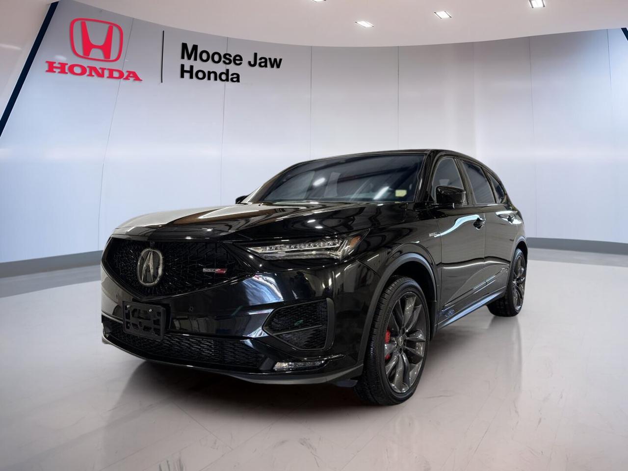 Meet a premium performance SUV that blends power, comfort, and everyday ease. This used 2023 Acura MDX Type S at Moose Jaw Honda in Moose Jaw offers bold style in Black, confident all-wheel drive, and a refined driving feel. With 58,300 km, it delivers luxury and performance in one well-rounded package.

The 2023 Acura MDX Type S stands out with a turbocharged 3.0-litre DOHC i-VTEC V6 engine, direct injection, and a 10-speed automatic transmission with paddle shifters. This setup gives you smooth power delivery, quick response, and strong highway confidence. Acuras focus on control and balance is clear in every drive.

FEATURES OF THE MDX Type S

»» Turbocharged V6 power for brisk acceleration
»» Super Handling All-Wheel Drive adds confidence
»» 10-speed automatic with paddle shifters
»» Black exterior brings sleek premium presence

ADVANCED SAFETY FEATURES

»» AcuraWatch suite supports safer daily driving
»» Collision mitigation braking helps avoid impacts
»» Lane keeping assist supports highway control
»» Adaptive cruise control eases long trips

PERFORMANCE AND EFFICIENCY

»» 3.0-litre turbo V6 delivers strong output
»» 10-speed automatic shifts smoothly and quickly
»» All-wheel drive improves year-round traction
»» Paddle shifters add engaging driver control

COMFORT AND CONVENIENCE

»» Spacious cabin suits family travel well
»» Easy entry supports busy daily use
»» Tri-row layout adds flexible passenger room
»» Premium ride comfort on city roads

TECHNOLOGY AND CONNECTIVITY

»» Clear driver displays keep information visible
»» Bluetooth connectivity supports hands-free calling
»» User-friendly interface simplifies daily operation
»» Steering wheel controls aid convenience

CARGO SPACE

»» Flexible cargo area handles daily gear
»» Rear storage supports weekend travel needs
»» Split-folding seats expand carrying versatility
»» Wide opening helps loading larger items

AWARDS & RECOGNITIONS

»» Top Safety Pick+, Insurance Institute for Highway Safety, 2023

WHAT OTHER OWNERS LIKE

»» Strong turbo power feels smooth daily
»» Confident all-wheel drive in poor weather
»» Comfortable ride for families and commuters
»» Quiet cabin on long highway drives

This used 2023 Acura MDX Type S is a smart choice for drivers who want premium space, athletic performance, and trusted Acura engineering. Its Black finish adds a clean, upscale look, while the all-wheel drive system helps you stay composed through changing Saskatchewan conditions.

The 2023 Acura MDX Type S is also well suited to busy family life. It offers the versatility of an SUV with the response of a performance model. From errands around Moose Jaw to longer road trips, it brings comfort, control, and confidence to every kilometre.

This 2023 Acura MDX Type Ss VIN is: 5J8YD8H92PL800169 .