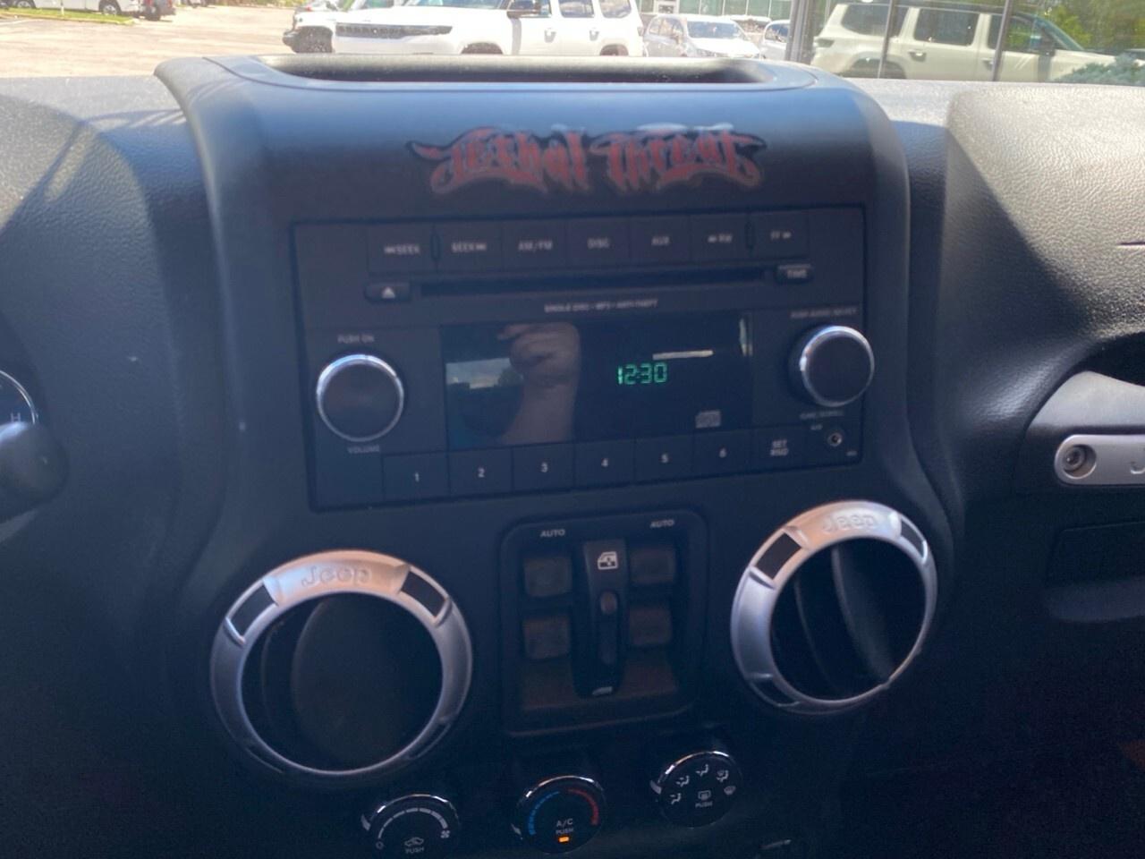 2012 Jeep WRANGLER UNLIMITED 4WD 4dr Sahara Photo