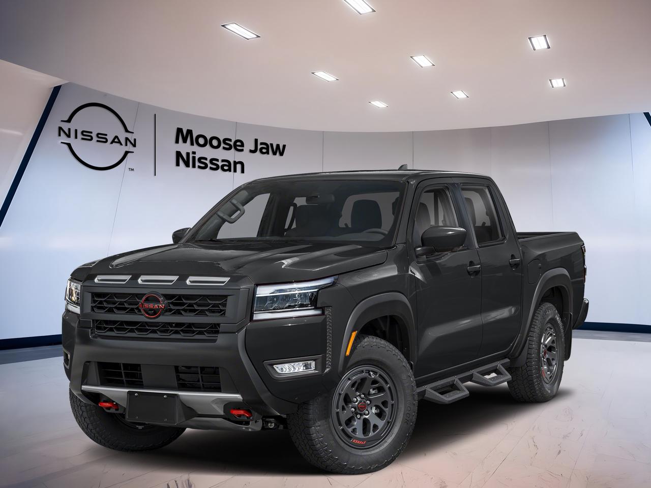 Meet the brand new 2026 Nissan Frontier Pro-4x at Moose Jaw Nissan in Moose Jaw. Finished in Black with a Black interior, this midsize truck blends rugged 4x4 ability with proven V6 power. Its 3.8-litre direct-injection V6 and 9-speed automatic transmission deliver smooth response, confident passing power, and solid everyday drivability.

Built for drivers who want real truck strength without giving up comfort, the 2026 Nissan Frontier Pro-4x brings a durable body-on-frame design and four-wheel drive for work, weekends, and prairie weather. This new Frontier Pro-4x offers the toughness many truck buyers want, with the simple confidence of a naturally aspirated V6.

FEATURES OF THE Frontier Pro-4x
»» Off-road tuned suspension for rough trails
»» Four-wheel drive for added traction
»» Strong 3.8-litre V6 power delivery
»» Nine-speed automatic supports smooth shifting

TRUCK FEATURES
»» Body-on-frame design adds lasting truck durability
»» Four-wheel drive helps on loose surfaces
»» Pickup box supports gear and jobsite use
»» V6 power suits towing and hauling

ADVANCED SAFETY FEATURES
»» Strong truck structure supports occupant protection
»» Four-wheel drive aids slippery road control
»» High driving position improves forward visibility
»» Anti-lock braking supports controlled stopping

PERFORMANCE AND EFFICIENCY
»» 3.8-litre V6 delivers proven horsepower
»» Direct injection helps optimize engine response
»» Idle stop-start helps reduce fuel use
»» Nine-speed automatic enables smooth acceleration

COMFORT AND CONVENIENCE
»» Spacious cabin supports daily driving comfort
»» Automatic transmission reduces driving effort
»» Black interior gives a clean look
»» Four-door layout improves passenger access

TECHNOLOGY AND CONNECTIVITY
»» Modern controls designed for easy operation
»» Driver information display keeps data visible
»» Automatic transmission supports seamless driving feel
»» Useful cabin layout keeps essentials close

CARGO SPACE
»» Open pickup bed carries bulky items
»» Truck box suits tools and weekend gear
»» Cabin storage helps organize small items
»» Rear space adds flexibility for passengers

WHAT OTHER OWNERS LIKE
»» Strong V6 performance in daily use
»» Confident four-wheel drive in winter
»» Comfortable size for city and trails
»» Durable truck feel with smooth ride

This 2026 Nissan Frontier Pro-4xs VIN is: 1N6ED1EK3TN668907.<p>Meet the brand new 2026 Nissan Frontier Pro-4x at Moose Jaw Nissan in Moose Jaw. Finished in Black with a Black interior</p>
<p> this midsize truck blends rugged 4x4 ability with proven V6 power. Its 3.8-litre direct-injection V6 and 9-speed automatic transmission deliver smooth response</p>
<p> and solid everyday drivability.

Built for drivers who want real truck strength without giving up comfort</p>
<p> with the simple confidence of a naturally aspirated V6.

FEATURES OF THE Frontier Pro-4x
»» Off-road tuned suspension for rough trails
»» Four-wheel drive for added traction
»» Strong 3.8-litre V6 power delivery
»» Nine-speed automatic supports smooth shifting

TRUCK FEATURES
»» Body-on-frame design adds lasting truck durability
»» Four-wheel drive helps on loose surfaces
»» Pickup box supports gear and jobsite use
»» V6 power suits towing and hauling

ADVANCED SAFETY FEATURES
»» Strong truck structure supports occupant protection
»» Four-wheel drive aids slippery road control
»» High driving position improves forward visibility
»» Anti-lock braking supports controlled stopping

PERFORMANCE AND EFFICIENCY
»» 3.8-litre V6 delivers proven horsepower
»» Direct injection helps optimize engine response
»» Idle stop-start helps reduce fuel use
»» Nine-speed automatic enables smooth acceleration

COMFORT AND CONVENIENCE
»» Spacious cabin supports daily driving comfort
»» Automatic transmission reduces driving effort
»» Black interior gives a clean look
»» Four-door layout improves passenger access

TECHNOLOGY AND CONNECTIVITY
»» Modern controls designed for easy operation
»» Driver information display keeps data visible
»» Automatic transmission supports seamless driving feel
»» Useful cabin layout keeps essentials close

CARGO SPACE
»» Open pickup bed carries bulky items
»» Truck box suits tools and weekend gear
»» Cabin storage helps organize small items
»» Rear space adds flexibility for passengers

WHAT OTHER OWNERS LIKE
»» Strong V6 performance in daily use
»» Confident four-wheel drive in winter
»» Comfortable size for city and trails
»» Durable truck feel with smooth ride

This 2026 Nissan Frontier Pro-4xs VIN is: 1N6ED1EK3TN668907.</p>