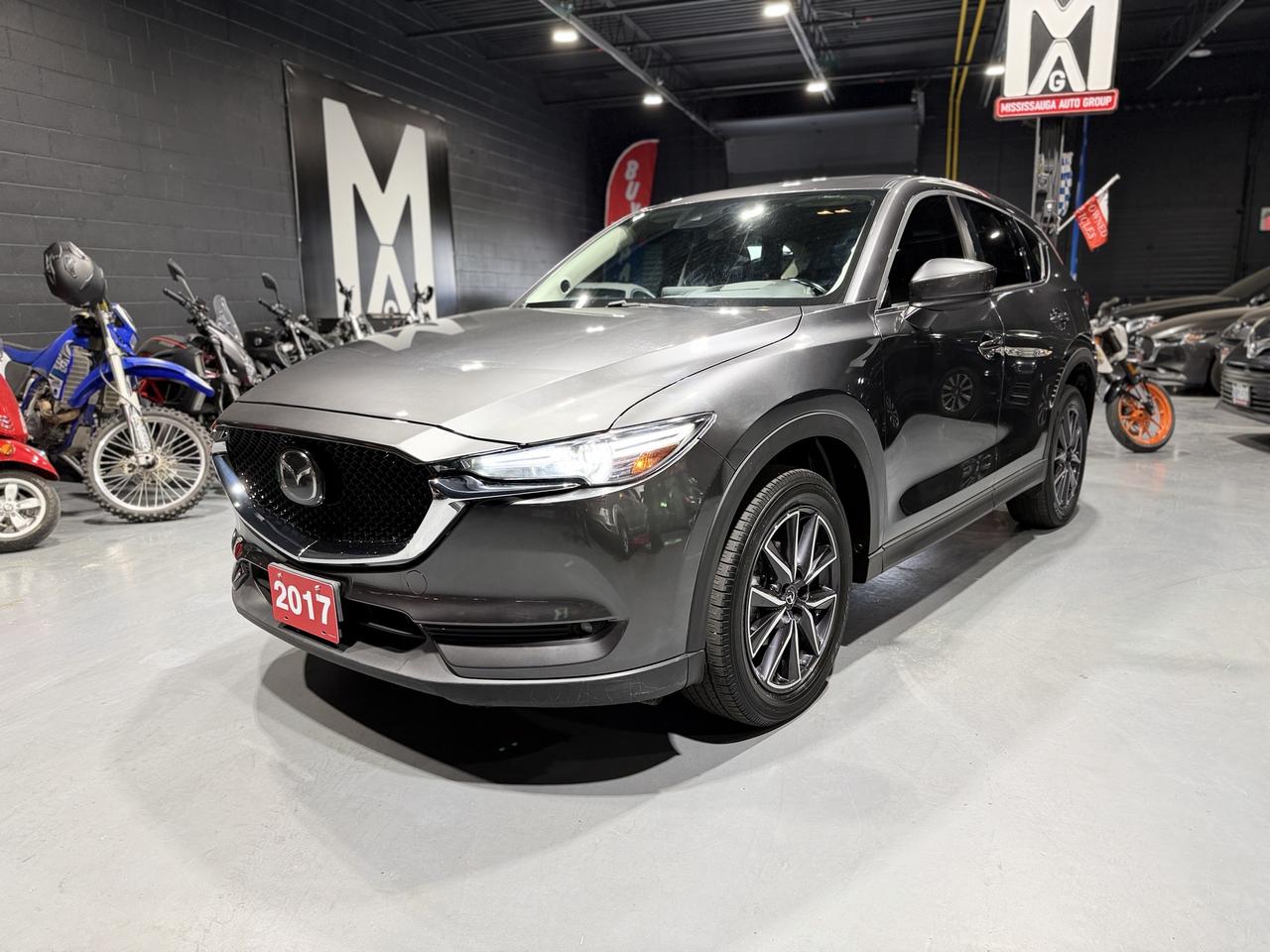 <p class=isSelectedEnd>🔥 <strong>2017 Mazda CX-5 GT | One Owner | Fully Loaded | Luxury SUV 🔥</strong></p><p class=isSelectedEnd>🖤 <strong>Carfax Verified | One Owner | Priced to Sell!</strong> 🖤</p><p class=isSelectedEnd>💎 <strong>Premium Comfort &bull; Advanced Technology &bull; Mazda Reliability</strong> 💎</p><p class=isSelectedEnd>Experience the perfect balance of luxury, performance, and practicality with this <strong>2017 Mazda CX-5 GT</strong>. This <strong>one-owner</strong>, <strong>Carfax Verified</strong> SUV has been well maintained and is fully loaded with premium features, making it the perfect choice for families, commuters, or anyone looking for a stylish and dependable SUV.</p><p class=isSelectedEnd>Powered by Mazdas responsive <strong>2.5L SKYACTIV-G 4-cylinder engine</strong> paired with a smooth <strong>automatic transmission</strong>, the CX-5 delivers impressive fuel economy, confident handling, and the driving experience Mazda is known for.</p><div contenteditable=false><hr></div><p class=isSelectedEnd>🚀 <strong>Performance & Driving Features</strong></p><p class=isSelectedEnd>✔ 2.5L SKYACTIV-G 4-Cylinder Engine<br>✔ Automatic Transmission<br>✔ Excellent Fuel Economy ⛽<br>✔ Smooth & Responsive Handling<br>✔ Alloy Wheels ✨<br>✔ Comfortable & Quiet Ride<br>✔ Proven Mazda Reliability ✅</p><div contenteditable=false><hr></div><p class=isSelectedEnd>🛋️ <strong>Premium GT Interior</strong></p><p class=isSelectedEnd>Enjoy a refined cabin packed with comfort and convenience features.</p><p class=isSelectedEnd>✨ <strong>Interior Highlights:</strong></p><p class=isSelectedEnd>✔ Premium Leather Interior<br>✔ Power Sunroof ☀️<br>✔ Heads-Up Display (HUD) 🛣️<br>✔ Heated Front Seats 🔥<br>✔ Heated Steering Wheel 🔥<br>✔ Power Drivers Seat<br>✔ Dual-Zone Climate Control ❄️<br>✔ Push Button Start<br>✔ Keyless Entry 🔑<br>✔ Cruise Control<br>✔ Split Folding Rear Seats 📦<br>✔ Spacious Cargo Area</p><div contenteditable=false><hr></div><p class=isSelectedEnd>📱 <strong>Technology & Entertainment</strong></p><p class=isSelectedEnd>Stay connected wherever you go.</p><p class=isSelectedEnd>✔ Touchscreen Display<br>✔ Bluetooth Hands-Free Calling & Audio 🎵<br>✔ Backup Camera 📸<br>✔ USB Connectivity<br>✔ Steering Wheel Audio Controls<br>✔ Voice Command Features<br>✔ AM/FM Radio</p><div contenteditable=false><hr></div><p class=isSelectedEnd>🛡️ <strong>Safety Features</strong></p><p class=isSelectedEnd>Drive with confidence thanks to Mazdas advanced safety technology.</p><p class=isSelectedEnd>✔ Backup Camera 📸<br>✔ Blind Spot Monitoring<br>✔ Rear Cross Traffic Alert<br>✔ Heads-Up Display (HUD) 🛣️<br>✔ Traction Control<br>✔ Electronic Stability Control<br>✔ ABS Brakes<br>✔ Multiple Airbags<br>✔ Tire Pressure Monitoring System</p><div contenteditable=false><hr></div><p class=isSelectedEnd>🌟 <strong>Vehicle Highlights</strong></p><p class=isSelectedEnd>✅ One Owner Vehicle 👤<br>✅ Carfax Verified ✔️<br>✅ <strong>125,450 KM</strong><br>✅ Fully Loaded GT Trim 💎<br>✅ Leather Interior<br>✅ Power Sunroof ☀️<br>✅ Heads-Up Display 🛣️<br>✅ Heated Seats & Heated Steering Wheel 🔥<br>✅ Alloy Wheels ✨<br>✅ Well Maintained & Ready to Drive ✔️</p><div contenteditable=false><hr></div><p class=isSelectedEnd>💲 <strong>ONLY $17,950 + Tax & Licensing</strong></p><p class=isSelectedEnd>🔥 <strong>Priced to Sell! Dont Miss Out!</strong> 🔥</p><p class=isSelectedEnd>This fully loaded <strong>2017 Mazda CX-5 GT</strong> offers luxury, reliability, and outstanding value at an unbeatable price. Clean, well maintained, and ready for its next owner.</p><p class=isSelectedEnd>🚗 <strong>Financing Available</strong><br>🛡️ <strong>Extended Warranty Options Available</strong></p><p class=isSelectedEnd>📞 <strong>Contact Today to Schedule Your Test Drive!</strong></p><p class=isSelectedEnd>📍 <strong>Saifi Motors</strong><br>2666 Royal Windsor Drive, Unit 11 & 12<br>Mississauga, ON L5J 4N1</p><p>📞 <strong>Call or Text:</strong> 416-816-2325<br>🌐 <a href=http://www.saifimotors.ca/><strong>www.saifimotors.ca</strong></a><br>📧 <a href=mailto:saifimotorsinc@gmail.com><strong>saifimotorsinc@gmail.com</strong></a></p>