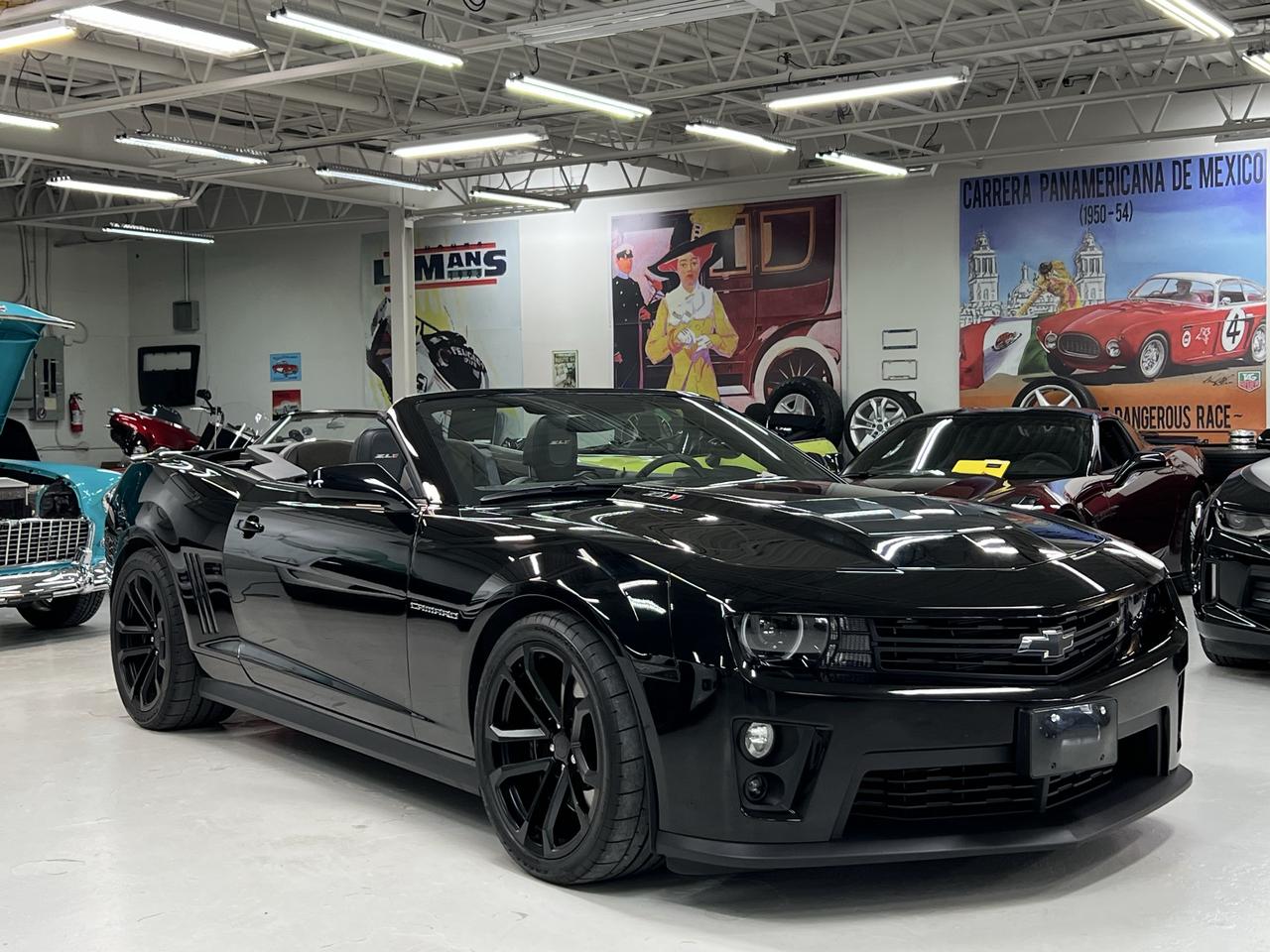 <h3>580 Supercharged Horsepower | Only 44,243 KM | Magnetic Ride | Navigation | Museum Quality</h3><p>Some cars are fast.</p><p>Some cars are memorable.</p><p>The <strong>Camaro ZL1</strong> is both.</p><p>Powered by Chevrolets legendary <strong>6.2-litre supercharged LSA V8</strong>, the ZL1 produces <strong>580 horsepower and 556 lb-ft of torque</strong>, delivering effortless acceleration accompanied by one of the most intoxicating exhaust notes ever to come out of Detroit.</p><p>This exceptional Canadian ZL1 Convertible has travelled just <strong>44,243 kilometres</strong> and is presented in timeless <strong>Black</strong> over a <strong>Jet Black suede and leather interior</strong> with the factory carbon flash trim. It remains in outstanding condition and has clearly been cared for throughout its life.</p><p>Equipped with the <strong>6-speed automatic transmission</strong>, the ZL1 combines brutal performance with effortless cruising. Chevrolets <strong>Magnetic Ride Control</strong> continuously adjusts the suspension hundreds of times per second, giving this car remarkable comfort on the highway while transforming into a true performance machine when the road begins to twist.</p><h3>Factory Highlights</h3><ul><li><p>6.2L Supercharged LSA V8</p></li><li><p>580 Horsepower</p></li><li><p>6-Speed Automatic Transmission</p></li><li><p>Magnetic Ride Control</p></li><li><p>Performance Dual-Mode Exhaust</p></li><li><p>Limited Slip Differential</p></li><li><p>Brembo Heavy-Duty Performance Brakes</p></li><li><p>Heads-Up Display</p></li><li><p>Navigation System</p></li><li><p>Rear Vision Camera</p></li><li><p>Rear Park Assist</p></li><li><p>Heated Power Sport Seats</p></li><li><p>Suede Seat Inserts</p></li><li><p>Suede Shift Knob</p></li><li><p>Premium Boston Acoustics Audio System</p></li><li><p>Bluetooth Audio & Phone Connectivity</p></li><li><p>Remote Start</p></li><li><p>Universal Garage Door Opener</p></li><li><p>HID Headlamps</p></li><li><p>Fog Lamps</p></li><li><p>Carbon Flash Interior Trim</p></li><li><p>Black Power Convertible Top</p></li></ul><p>This is far more than simply a high-horsepower Camaro. The ZL1 was engineered to compete with the worlds finest performance cars, featuring track-developed cooling, suspension, braking and aerodynamics that make it equally comfortable on a cross-country tour or a spirited weekend drive.</p><p>With collector interest continuing to grow in supercharged V8 performance cars, low-kilometre, unmodified ZL1s have become increasingly difficult to find. The 2014 model represents the final evolution of the fifth-generation Camaro before the sixth-generation redesign and is widely regarded as one of Chevrolets greatest modern muscle cars.</p><p>This ZL1 has been fully inspected, professionally detailed and is ready for its next enthusiast owner.</p><p>At <strong>Lee Munros Garage</strong>, we carefully select vehicles that stand apart from the ordinary.</p><p><strong>Easy to buy. A pleasure to own. Guaranteed.</strong></p><p><strong>Lee Munros Garage</strong></p><p><em>Because some cars are transportation, and some cars make life better.</em></p>