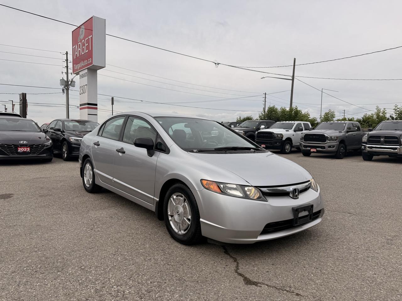 <p>Looking for a reliable and stylish ride that wont break the bank? Target Auto Centre has just what you need with this gleaming silver 2008 Honda Civic DX-G. This sedan is a fantastic choice for anyone seeking a dependable vehicle thats been meticulously cared for. With just one owner and a history of excellent maintenance, you can drive away with peace of mind knowing this Civic has been cherished. The spacious grey interior offers comfort for both driver and passengers, making every journey a pleasure.&nbsp;Under the hood, youll find a fuel-efficient 1.8L I4 engine paired with a smooth automatic transmission, delivering a responsive and enjoyable driving experience perfect for navigating city streets or cruising on the highway. The front-wheel drive ensures confident handling in various Canadian driving conditions. This 2008 Honda Civic DX-G has traveled 133,036 km and is ready for many more adventures with its next owner.</p><p>&nbsp;</p><hr><p>&nbsp;</p><p dir=ltr><strong>CERTIFIED PRE-OWNED VEHICLE | BUY WITH CONFIDENCE</strong></p><p dir=ltr>&nbsp;- Ontario Safety Standards Certificate Included<br>- 30 Day / 1,000 KM Safety Warranty Included<br>- Fully Detailed Prior to Delivery<br>- CARFAX Vehicle History Report Available<br>&nbsp; (View on Our Website)</p><p>&nbsp;</p><hr><p>&nbsp;</p><p dir=ltr><strong>VALUE AND TRANSPARENCY | WHY CHOOSE US</strong></p><p dir=ltr>- Price Plus HST & Licensing Only<br>- No Additional Fees | All-In Pricing<br>- Same Price Cash or Finance<br>- Extended Warranty Protection Plans Available<br>- Autotrader Best Priced Dealer Award (2024)<br>- Competitive Market Value on Trade-ins<br>- We&rsquo;ll Buy Your Car &mdash; No Purchase Required<br>- Know Someone Looking For a Vehicle? Get a Referral Award<br>- Open 7 Days a Week</p><p>&nbsp;</p><hr><p>&nbsp;</p><p dir=ltr><strong>ABOUT TARGET AUTO CENTRE</strong></p><p dir=ltr>Target Auto Centre has been proudly serving London, Ontario and surrounding areas for over 20 years, offering over 150 quality pre-owned vehicles and a constantly updated selection to choose from. We focus on providing competitive pricing, clear information, and a straightforward buying process so you know exactly what to expect from start to finish.</p><p dir=ltr>Cars For Everyone! We offer a wide selection of vehicles to fit every lifestyle, need, and budget. Our inventory includes cars, trucks, SUVs, and vans from trusted brands such as Ford, Chevrolet, Toyota, Honda, Nissan, BMW, Mercedes-Benz, Audi, Lexus, Acura, Hyundai, Kia, Mazda, Volkswagen, Jeep, RAM, GMC, Subaru, and more. With new arrivals regularly, there&rsquo;s always something for everyone.</p><p dir=ltr>As a proud member of the Used Car Dealers Association of Ontario (UCDA), we are committed to operating with honesty, transparency, and professionalism in every transaction. Our goal is to make your vehicle purchase as simple and stress-free as possible, while delivering the level of service our customers continue to trust. Come visit us today and see why were the preferred choice for pre-owned vehicles in London and the surrounding areas. We look forward to earning your business!</p>